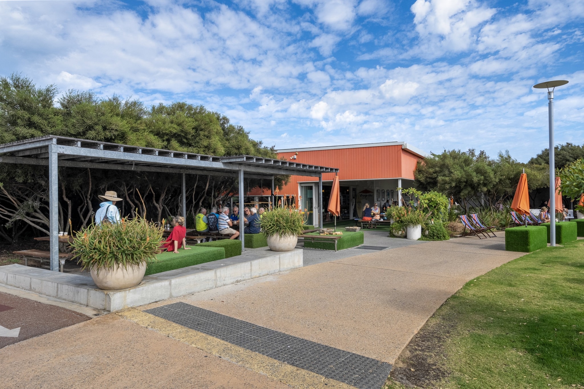 Experience North Fremantle from this bright studio retreat, perfect for couples or solo travellers. Enjoy ducted air-conditioning, a queen bed, and access to a communal rooftop area. The studio includes a fully equipped kitchen and Wi-Fi, with key collection available onsite.
Public Transport
North Fremantle Station is a short walk away, offering direct trains to Perth CBD and Fremantle. Local buses run to Cottesloe and surrounding suburbs.
Getting There
About 35 mins by car from Perth Airport and 25 mins from Perth CBD.
The space
This stylish studio offers a serene, open-plan layout with soft-toned décor, curated furnishings, and natural lighting. A plush queen bed sits across from the living area, where a smart TV and a comfortable 2-seater couch invite relaxation. The kitchen is well-appointed with modern electric appliances, a coffee machine, and a dining table for two. Though compact, the layout maximises comfort and functionality. The modern bathrooms offer added convenience. Grey tiled floors run throughout, complementing a sleek, contemporary aesthetic. While there’s no private outdoor space, guests have access to a communal rooftop and BBQ are on Level 5, accessible via lift. This retreat is ideal for travellers seeking a coastal stay with modern amenities.
Living Room
-Couch seats 2 people
-TV with Free-to-Air, streaming & Chromecast (guests to use their own credentials)
Kitchen & Dining Area
-Fully equipped with cookware, cutlery, and utensils
-Convection microwave and induction 2-burner stovetop
-Dining area seats 2
-Air fryer is available
Bathroom & Laundry
-Travel essentials, towels and hairdryer provided
-No laundry facilities available
Amenity Notes
-The communal rooftop pool
-No onsite parking
-Ducted A/C (heating + cooling) throughout
-Wi-Fi is available
-Rooftop area, BBQ, and lounge area on level 5
-Yoga studio available on ground level (additional cost, independently operated)