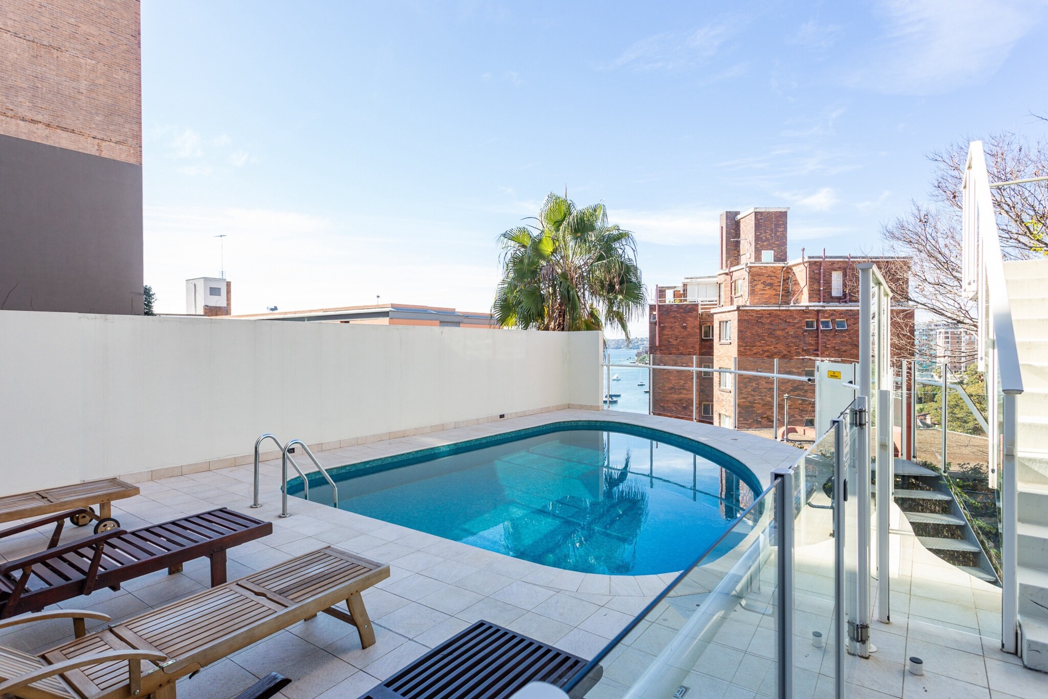 Enjoy a bright and spacious studio in vibrant Elizabeth Bay. This city-edge retreat features blackout blinds, central A/C, and easy self-check-in via onsite lockbox. Ideal for solo travellers or couples, with communal coin-operated laundry, building pool, and harbour walks nearby.
Public Transport
Bus stops along Macleay St and Elizabeth Bay Rd connect to the CBD and Bondi. Kings Cross Station (T4 line) is 8 min walk.
Getting There
Approx. 25 min drive from Sydney Airport. Around 10 min drive or 15 min train ride to Sydney CBD.
The space
This inviting studio blends simplicity with convenience in a sought-after harbourside location. The main room features a plush queen bed with soft lighting from twin bedside lamps and stylish wooden furnishings, including bedside tables and ample hangers. Large windows provide abundant natural light, enhanced by full blackout blinds for restful nights. The space is tiled throughout and styled with a neutral palette, accented by a decorative rug and practical storage. A compact kitchenette offers essential cookware, an electric stovetop, and a microwave, ideal for easy meals. Two countertop stools provide casual dining seating. The bathroom includes a toilet and shower, with towels and travel essentials provided. Communal coin-operated laundry facilities are located on the same level. Guests can also enjoy access to an outdoor building pool situated on the ground floor.
Living Room
- Studio layout includes a queen bed
- TV with free-to-air channels & digital streaming platforms (guests to use their own credentials)
- Styled with decorative rug and soft furnishings
Kitchen & Dining Area
- Fully equipped with cutlery, and utensils
- Electric stovetop
- Countertop seats 2
Bathroom & Laundry
- Communal and coin-operated laundry available with washer and dryer
- Travel essentials, towels and hairdryer provided
Amenity Notes
- Portable heater
- Parking: Street parking with 2hr and 4hr limits
- A/C: Centralised A/C controlled by wall switch near TV
- Wi-Fi is available
- Private Amenities: Outdoor building pool located on the ground floor
Local area description
Located in Elizabeth Bay, the studio offers easy access to Sydney Harbour's picturesque walks, Potts Point’s eclectic dining scene, and the Royal Botanic Garden. Enjoy a city-meets-coast lifestyle with vibrant cafés, weekend markets, and peaceful harbourside parks just moments away.
House rules
You are staying in a friendly and peaceful neighbourhood and we kindly ask you to respect the community and your surrounding neighbours. The following strict House Rules apply:
- No loud noise between 10 pm and 8 am
- No parties or antisocial behaviour
- No additional people are to access the property without our prior approval
- No pets are allowed in the property without approval
- No smoking is allowed at any times
- If you break something, please let us know
- To help protect all floor coverings, do not wear any shoes inside the property
Please be aware that excessive noise such as amplified music, vocals or screaming or anti-social behaviour in the property or common areas can cause neighbours to complain to us, the Building Manager, Council Rangers or Police.
IMPORTANT:
- Any breach of the House Rules may lead to a $500 fine plus compensation for any cost/damage created and immediate eviction of the property without refund.
- Pets are available on request unless the property states it is pet friendly. Any stays with pets will incur an additional cleaning fee of $200.
Finally, when checking out, we kindly ask you for the following:
- Please leave all beds unmade
- Please clean up your dishes and put them away
- In case you have rearranged furniture, please put it back to the original location
- Please take out the rubbish and remember to use the right bins
- Please ensure all appliances, A/C and lights are off and doors and windows are closed.
- Please check your accommodation thoroughly before departing to avoid any unintentional items left behind.
We are not liable for any items left behind after your stay. In the rare event that a guest reports a missing item, we will make every effort to locate it for you, but we cannot guarantee its retrieval. If the item is found, we will gladly assist in arranging its return to an address within Australia, subject to postage and service fees.
Interaction with guests
Welcome to MadeComfy! Our local team curates stays in exceptional Australian & New Zealand properties, ensuring style, comfort, and prime locations for discerning guests. We prioritise your needs to provide a memorable home-away-from-home experience. Explore our digital guidebooks for local recommendations, and don't hesitate to contact us throughout your stay. We're here to ensure your comfort - enjoy your stay with MadeComfy.
Notes
- There is a construction site directly in front of the bedroom; noise may be experienced from early morning through the day
- Pool is on the ground floor (not rooftop); access instructions in the guest guide
For your comfort, this property is prepared with professional-grade hotel-style linen, including a three-sheet setup, ensuring a fresh and hygienic sleep experience.
Extra Services:
- Early Check-in: Our standard check-in is at 3 pm. To guarantee early access to the property we suggest booking the night before if available. Otherwise, early check-in is subject to availability from the night before at an additional cost.
- Late check-out: Our standard check-out is at 10 am. To guarantee a later check-out of the property we suggest booking an additional night if available. Otherwise, a late check-out is subject to availability from the night before to an additional cost.
- Baggage: For security reasons, we are unable to receive or to keep unattended baggage before check-in or after check-out
- We provide a small welcome amenity pack to get your stay started.
- This booking is protected with coverage for lost baggage and emergency medical expenses, provided by Travel Support with claim upto 500 AUD (T&C Applies). For more details reach out to Guest Support team post booking.
Access description
Key collection is onsite. Further details will be provided 3 days before check-in if your booking is successfully reserved.
Getting around
Public Transport
Bus stops along Macleay St and Elizabeth Bay Rd connect to the CBD and Bondi. Kings Cross Station (T4 line) is 8 min walk.
Getting There
Approx. 25 min drive from Sydney Airport. Around 10 min drive or 15 min train ride to Sydney CBD.