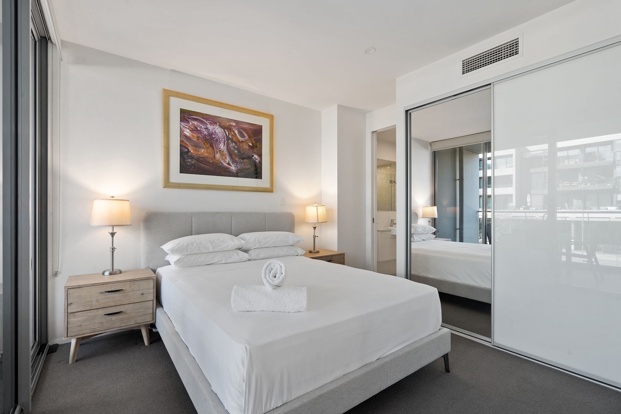 Property description
This bright and spacious 2-bedroom apartment is ideally located by the picturesque Kingston Lake, offering a serene escape. Guests will enjoy the comfort of stylish interiors, a fully equipped kitchen, and access to a ground-level pool. Featuring modern amenities, including Wi-Fi and air-conditioning, it's perfect for both short and long stays. Enjoy easy access to local cafés, shops, and more in this peaceful, central location.
The space
This well-designed 2-bedroom apartment offers ample space with modern touches and functional design. The open-plan living and dining area features a comfy sofa and a dining table, while the kitchen is fully equipped with everything you need for a home-cooked meal. Each bedroom is adorned with blackout blinds for a restful sleep, complemented by quality mattresses. Step outside through the sliding doors into the private outdoor space, perfect for unwinding. The apartment boasts ducted air-conditioning, ensuring comfort in every season.