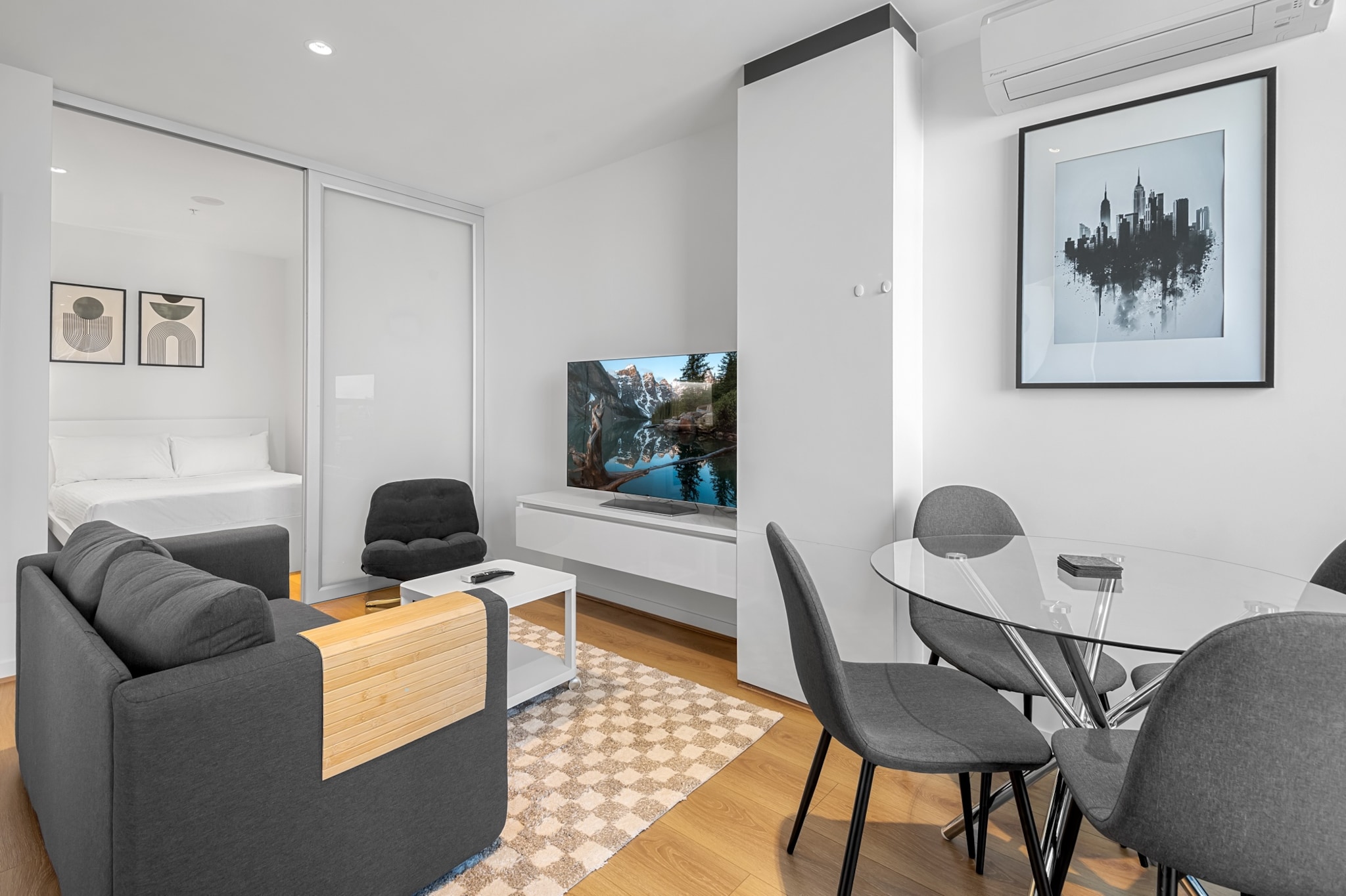 Experience elevated city living in this elegant 2-bedroom apartment with access to premium facilities including a pool, sauna, and gym. Enjoy a private balcony, sleek interiors, self-check-in and Wi-Fiâ€”all just moments from Southern Cross Station and Melbourneâ€™s best attractions.
The space
This inviting 2-bedroom apartment offers a bright, open-plan layout framed by floor-to-ceiling windows and warm timber flooring. Both bedrooms feature queen-sized beds, side tables, and soft lighting, while blackout blinds ensure restful sleep. The kitchen comes fully stocked and adjoins a dining area that seats four. A comfortable lounge with seating for two flows onto the private balcony, offering a charming urban outlook. The single bathroom includes a walk-in shower and modern vanity. A private laundry and smart TV round out this well-equipped urban retreat. Guests also enjoy access to building amenities including a 25m lap pool, sauna, gym, and a scenic garden terrace with BBQ facilities and a play area.
 
Living Room
- Couch seats 2 people + armchair
- Smart TV (guests to use their own credentials)
 
Kitchen & Dining Area
- Fully equipped with cutlery and utensils
- Electric oven and electric stovetop
- Dining area seats 4
 
Bathroom & Laundry
- Laundry room available with washer only
- Travel essentials, towels and hairdryer provided
 
Amenity Notes
- No parking
- Study nook at the entrance
- A/C (cooling + heating) in lounge only
- Wi-Fi is available
- City views from the windows
- Private Amenities: Balcony access from lounge with outdoor furniture for 2
- Building Amenities: 25m lap pool, sauna, gym, BBQ area, terrace garden, climbing wall and kidsâ€™ play area
Local area description
Located in the heart of Melbourne, this apartment offers easy access to vibrant laneways, shopping, and dining. Walk to Southern Cross Station, Queen Victoria Market, and Marvel Stadium. Ideal for those seeking culture, convenience, and city lifestyle.
House rules
You are staying in a friendly and peaceful neighbourhood and we kindly ask you to respect the community and your surrounding neighbours. The following strict House Rules apply:
 
- No loud noise between 10 pm and 8 am
- No parties or antisocial behaviour
- No additional people are to access the property without our prior approval
- No pets are allowed in the property without approval
- No smoking is allowed at any times
- If you break something, please let us know
- To help protect all floor coverings, do not wear any shoes inside the property
 
Please be aware that excessive noise such as amplified music, vocals or screaming or anti-social behaviour in the property or common areas can cause neighbours to complain to us, the Building Manager, Council Rangers or Police.
 
IMPORTANT:
- Any breach of the House Rules may lead to a $500 fine plus compensation for any cost/damage created and immediate eviction of the property without refund.
- Pets are available on request unless the property states it is pet friendly. Any stays with pets will incur an additional cleaning fee of $200.
 
Finally, when checking out, we kindly ask you for the following:
 
- Please leave all beds unmade
- Please clean up your dishes and put them away
- In case you have rearranged furniture, please put it back to the original location
- Please take out the rubbish and remember to use the right bins
- Please ensure all appliances, A/C and lights are off and doors and windows are closed.
- Please check your accommodation thoroughly before departing to avoid any unintentional items left behind.
 
We are not liable for any items left behind after your stay. In the rare event that a guest reports a missing item, we will make every effort to locate it for you, but we cannot guarantee its retrieval. If the item is found, we will gladly assist in arranging its return to an address within Australia, subject to postage and service fees.
Interaction with guests
Welcome to MadeComfy! Our local team curates stays in exceptional Australian & New Zealand properties, ensuring style, comfort, and prime locations for discerning guests. We prioritise your needs to provide a memorable home-away-from-home experience. Explore our digital guidebooks for local recommendations, and don't hesitate to contact us throughout your stay. We're here to ensure your comfort - enjoy your stay with MadeComfy.
Notes
- For your comfort, this property is prepared with professional-grade hotel-style linen, including a three-sheet setup, ensuring a fresh and hygienic sleep experience.
 
Extra Services:
- Early Check-in: Our standard check-in is at 3 pm. To guarantee early access to the property we suggest booking the night before if available. Otherwise, early check-in is subject to availability from the night before at an additional cost.
- Late check-out: Our standard check-out is at 10 am. To guarantee a later check-out of the property we suggest booking an additional night if available. Otherwise, a late check-out is subject to availability from the night before to an additional cost.
- Baggage: For security reasons, we are unable to receive or to keep unattended baggage before check-in or after check-out
- We provide a small welcome amenity pack to get your stay started.
- This booking is protected with coverage for lost baggage and emergency medical expenses, provided by Travel Support with claim upto 500 AUD (T&C Applies). For more details reach out to Guest Support team post booking.
Access description
The key collection is located offsite. Further details will be provided 3 days before check-in if your booking is successfully reserved.
Getting around
Public Transport
Southern Cross Station is a 3-min walk, with regional trains, SkyBus to the airport, trams, and buses nearby.
 
Getting There
Approx. 25 mins by car from Melbourne Airport (MEL) and 5 mins to Melbourne CBD.
