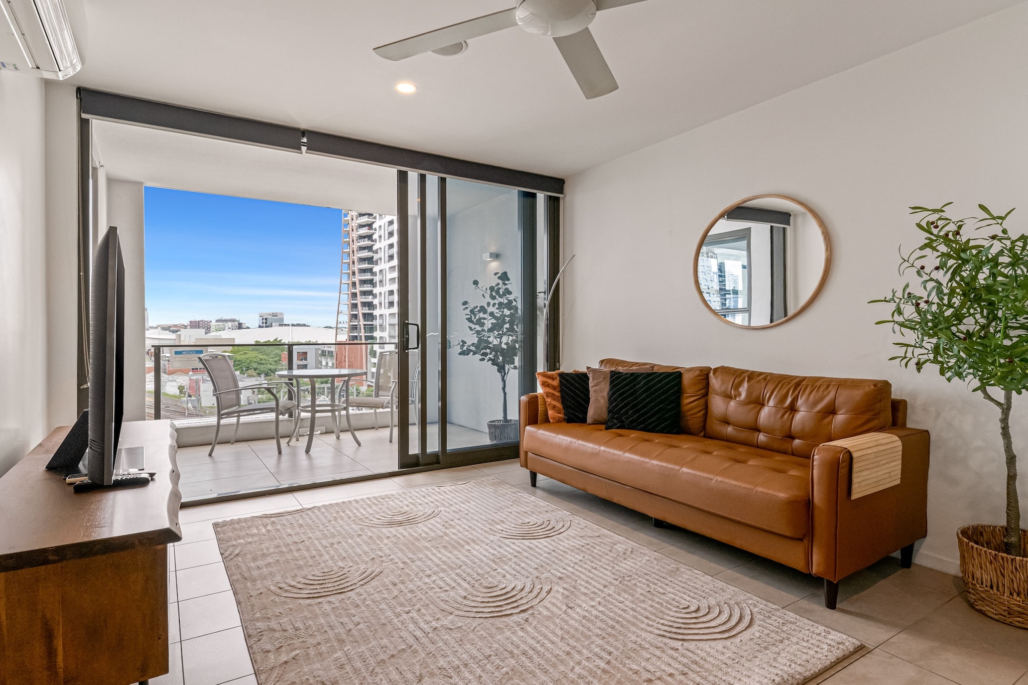 Enjoy the best of Brisbane from this bright and practical apartment in vibrant South Brisbane. With a comfortable queen bed, flexible second room, balcony, and access to a rooftop spa and BBQ area, this apartment is ideal for business or leisure stays. Located minutes from the river, museums, dining, and public transport. Onsite parking and self-check-in included.
The space
Step into a well-designed urban retreat featuring sleek tiled floors and a breezy open layout. The living room offers a couch and TV and opens onto a private balcony with an outdoor seating area, perfect for relaxing evenings. A dining area seats four, adjacent to a gas-equipped kitchen with essential cookware and utensils. The main bedroom features a queen bed, ceiling fan, and blackout blinds for restful nights, while the second room includes a single (and additional trundle bed), two single beds - ideal for children or extra guests. A single, well-maintained bathroom serves both rooms. Ceiling fans in each bedroom and the living area ensure comfort throughout, while a split system A/C is available in the living room and master bedroom. Guests also have access to a private laundry with a washer and dryer. Located in a secure building, this home includes access to a rooftop spa and BBQ facilities on Level 11. Whether you're working remotely or exploring the city, this apartment combines comfort, location, and convenience.
 
Living Room
- Couch seats 4 people
- TV with Free-to-Air channels
 
Kitchen & Dining Area
- Fully equipped with cutlery and utensils
- Oven and gas stovetop
- Dining area seats 4
 
Bathroom & Laundry
- Laundry room available with washer and dryer
- Travel essentials and towels
 
Amenity Notes
- Onsite parking space for 1 car (2.1M height limit)
- Split system A/C (heating + cooling) in the main bedroom
- Ceiling fans in both bedrooms & the living room
- Balcony with outdoor furniture
- Rooftop, spa and BBQ on Level 11
- WiFi is available
- Second bedroom has one single bed and one trundle bed
Local area description
Set in the cultural heart of South Brisbane, this apartment is surrounded by top-tier dining, museums, and riverside walks. Explore the Queensland Art Gallery, stroll through South Bank Parklands, or cross to the CBD within minutes. A vibrant and convenient base for city exploration.
House rules
You are staying in a friendly and peaceful neighbourhood and we kindly ask you to respect the community and your surrounding neighbours. The following strict House Rules apply:
 
- No loud noise between 10 pm and 8 am
- No parties or antisocial behaviour
- No additional people are to access the property without our prior approval
- No pets are allowed in the property without approval
- No smoking is allowed at any times
- If you break something, please let us know
- To help protect all floor coverings, do not wear any shoes inside the property
 
Please be aware that excessive noise such as amplified music, vocals or screaming or anti-social behaviour in the property or common areas can cause neighbours to complain to us, the Building Manager, Council Rangers or Police.
 
IMPORTANT:
- Any breach of the House Rules may lead to a $500 fine plus compensation for any cost/damage created and immediate eviction of the property without refund.
- Pets are available on request unless the property states it is pet friendly. Any stays with pets will incur an additional cleaning fee of $200.
 
Finally, when checking out, we kindly ask you for the following:
 
- Please leave all beds unmade
- Please clean up your dishes and put them away
- In case you have rearranged furniture, please put it back to the original location
- Please take out the rubbish and remember to use the right bins
- Please ensure all appliances, A/C and lights are off and doors and windows are closed.
- Please check your accommodation thoroughly before departing to avoid any unintentional items left behind.
 
We are not liable for any items left behind after your stay. In the rare event that a guest reports a missing item, we will make every effort to locate it for you, but we cannot guarantee its retrieval. If the item is found, we will gladly assist in arranging its return to an address within Australia, subject to postage and service fees.
Interaction with guests
Welcome to MadeComfy! Our local team curates stays in exceptional Australian & New Zealand properties, ensuring style, comfort, and prime locations for discerning guests. We prioritise your needs to provide a memorable home-away-from-home experience. Explore our digital guidebooks for local recommendations, and don't hesitate to contact us throughout your stay. We're here to ensure your comfort - enjoy your stay with MadeComfy.
Notes
- Stairs to the building entrance
 
For your comfort, this property is prepared with professional-grade hotel-style linen, including a three-sheet setup, ensuring a fresh and hygienic sleep experience.
 
Extra Services:
- Early Check-in: Our standard check-in is at 3 pm. To guarantee early access to the property we suggest booking the night before if available. Otherwise, early check-in is subject to availability from the night before at an additional cost.
- Late check-out: Our standard check-out is at 10 am. To guarantee a later check-out of the property we suggest booking an additional night if available. Otherwise, a late check-out is subject to availability from the night before to an additional cost.
- Baggage: For security reasons, we are unable to receive or to keep unattended baggage before check-in or after check-out
- We provide a small welcome amenity pack to get your stay started.
- This booking is protected with coverage for lost baggage and emergency medical expenses, provided by Travel Support with claim upto 500 AUD (T&C Applies). For more details reach out to Guest Support team post booking.
Access description
The key collection is located off-site (500m from the property) and is not available 24/7. Further details will be provided 3 days before check-in if your booking is successfully reserved.
Getting around
Public Transport
Bus stops, train stations, and South Bank ferry terminals are all within walking distance. South Brisbane Station is just 500m away.
 
Getting There
Approx. 20 mins by car from Brisbane Airport. 5 mins drive or 15 mins walk to Brisbane CBD.