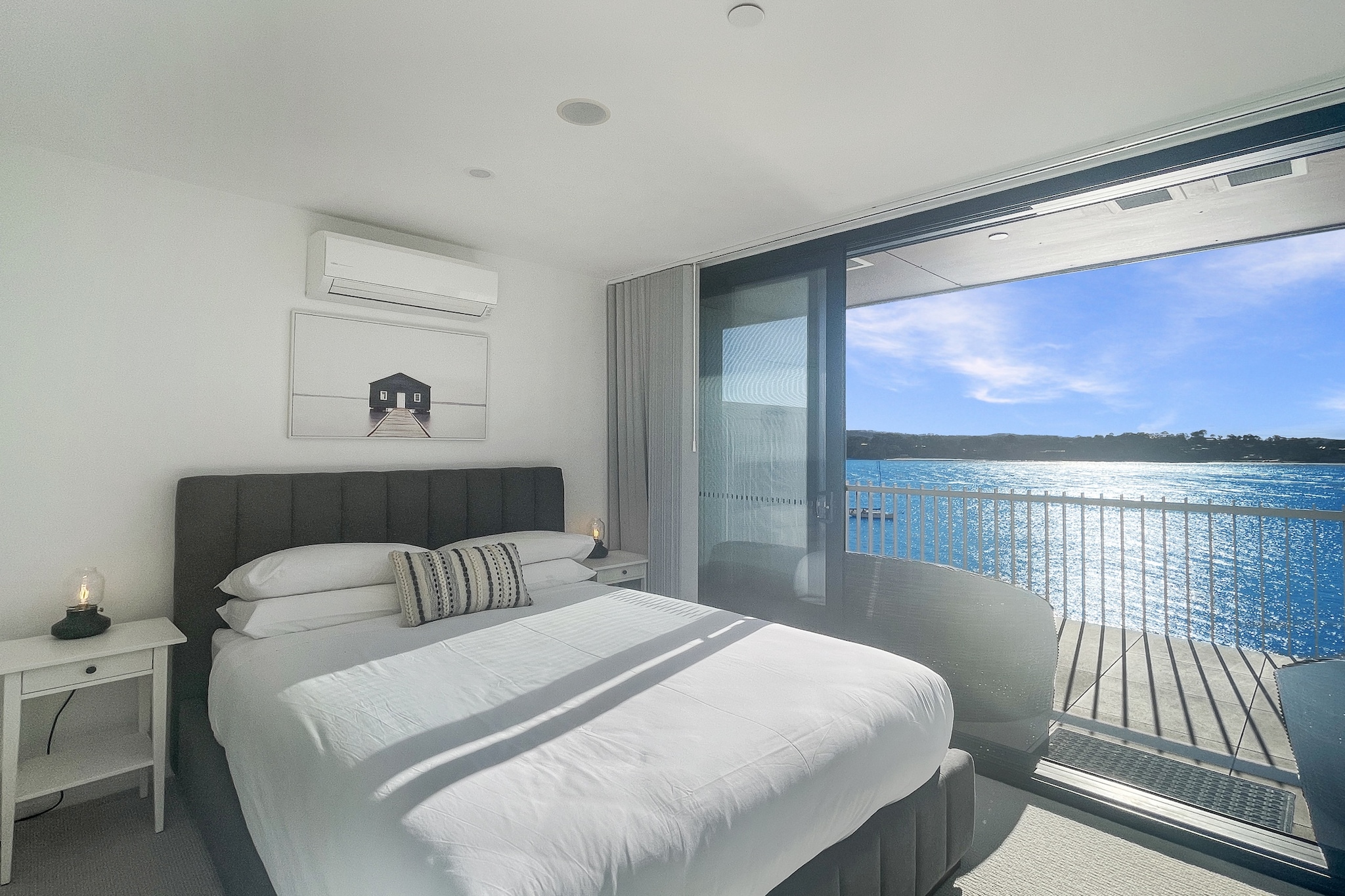 Step into the ultimate coastal escape in beautiful Batemans Bay- a vibrant seaside town known for its sparkling beaches, fresh seafood, and laid-back charm. This light-filled, modern 2-bedroom unit is your private sanctuary, offering everything you need for a truly relaxing and unforgettable getaway. Whether you’re a couple seeking a romantic retreat, a family on a sunny escape, or friends looking to unwind by the beach, this apartment has been designed to blend comfort, style, and convenience.
The space
Feel instantly at home in this light-filled, open-plan apartment designed for comfort and coastal relaxation. The spacious living area features a plush five-seater couch, a smart TV, and tasteful décor that reflects the laid-back charm of Batemans Bay. Sliding doors lead seamlessly to a private balcony - an ideal space for enjoying your morning coffee, unwinding with a sunset drink, or dining alfresco under the stars. Fitted with outdoor dining furniture and a BBQ, it’s perfect for those who enjoy outdoor living. Inside, the fully equipped kitchen includes a ceramic stovetop, electric oven, and all the cookware, utensils, and dinnerware you might need, while the adjacent dining area seats four comfortably - great for quick breakfasts or long, relaxed dinners. The apartment features two stylish queen bedrooms, each offering plush bedding, ample wardrobe space, and split system air conditioning to keep you comfortable year-round. The master bedroom includes its own en-suite and opens onto a second balcony, ideal for a peaceful morning retreat. A second full bathroom and a separate laundry with a washer and dryer provide added convenience, making this apartment a perfect choice for both short breaks and longer coastal getaways
 
Living Room
- Couch seats 5 people
- Smart TV with streaming apps (guests to use their own credentials)
 
Kitchen & Dining Area
- Fully equipped with cutlery and utensils
- Electric oven and ceramic stovetop
- Dining area seats 4
 
Bathroom & Laundry
- Laundry room available with washer and dryer
- Travel essentials, towels and hairdryer provided
 
Amenity Notes
- Onsite secure parking for 1 car (2.2m height limit)
- Split A/C (heating + cooling) in bedrooms and living area
- Wi-Fi is available
- Private balcony with full outdoor furniture and BBQ
- Communal rooftop pool on the 4th floor
House rules
You are staying in a friendly and peaceful neighbourhood and we kindly ask you to respect the community and your surrounding neighbours. The following strict House Rules apply:
 
- No loud noise between 10 pm and 8 am
- No parties or antisocial behaviour
- No additional people are to access the property without our prior approval
- No pets are allowed in the property without approval
- No smoking is allowed at any times
- If you break something, please let us know
- To help protect all floor coverings, do not wear any shoes inside the property
 
Please be aware that excessive noise such as amplified music, vocals or screaming or anti-social behaviour in the property or common areas can cause neighbours to complain to us, the Building Manager, Council Rangers or Police.
 
IMPORTANT:
- Any breach of the House Rules may lead to a $500 fine plus compensation for any cost/damage created and immediate eviction of the property without refund.
- Pets are available on request unless the property states it is pet friendly. Any stays with pets will incur an additional cleaning fee of $200.
 
Finally, when checking out, we kindly ask you for the following:
 
- Please leave all beds unmade
- Please clean up your dishes and put them away
- In case you have rearranged furniture, please put it back to the original location
- Please take out the rubbish and remember to use the right bins
- Please ensure all appliances, A/C and lights are off and doors and windows are closed.
- Please check your accommodation thoroughly before departing to avoid any unintentional items left behind.
 
We are not liable for any items left behind after your stay. In the rare event that a guest reports a missing item, we will make every effort to locate it for you, but we cannot guarantee its retrieval. If the item is found, we will gladly assist in arranging its return to an address within Australia, subject to postage and service fees.
Interaction with guests
Welcome to MadeComfy! Our local team curates stays in exceptional Australian & New Zealand properties, ensuring style, comfort, and prime locations for discerning guests. We prioritise your needs to provide a memorable home-away-from-home experience. Explore our digital guidebooks for local recommendations, and don't hesitate to contact us throughout your stay. We're here to ensure your comfort - enjoy your stay with MadeComfy.
Notes
- Stairs are inside the property
- The pool may be closed at any time for maintenance.
 
For your comfort, this property is prepared with professional-grade hotel-style linen, including a three-sheet setup, ensuring a fresh and hygienic sleep experience.
 
Extra Services:
- Early Check-in: Our standard check-in is at 3 pm. To guarantee early access to the property we suggest booking the night before if available. Otherwise, early check-in is subject to availability from the night before at an additional cost.
- Late check-out: Our standard check-out is at 10 am. To guarantee a later check-out of the property we suggest booking an additional night if available. Otherwise, a late check-out is subject to availability from the night before to an additional cost.
- Baggage: For security reasons, we are unable to receive or to keep unattended baggage before check-in or after check-out
- We provide a small welcome amenity pack to get your stay started.
- This booking is protected with coverage for lost baggage and emergency medical expenses, provided by Travel Support with claim upto 500 AUD (T&C Applies). For more details reach out to Guest Support team post booking.
Access description
Key collection is onsite. Further details will be provided 3 days before check-in if your booking is successfully reserved.
Getting around
Public Transport
Local bus services operate from Batemans Bay Coach Stop on Orient St (approx. 5–7 min walk). No train stations in town.
 
Getting There
Approx. 2h drive from Canberra Airport and 3h 30m from Sydney CBD via the Princes Hwy.
