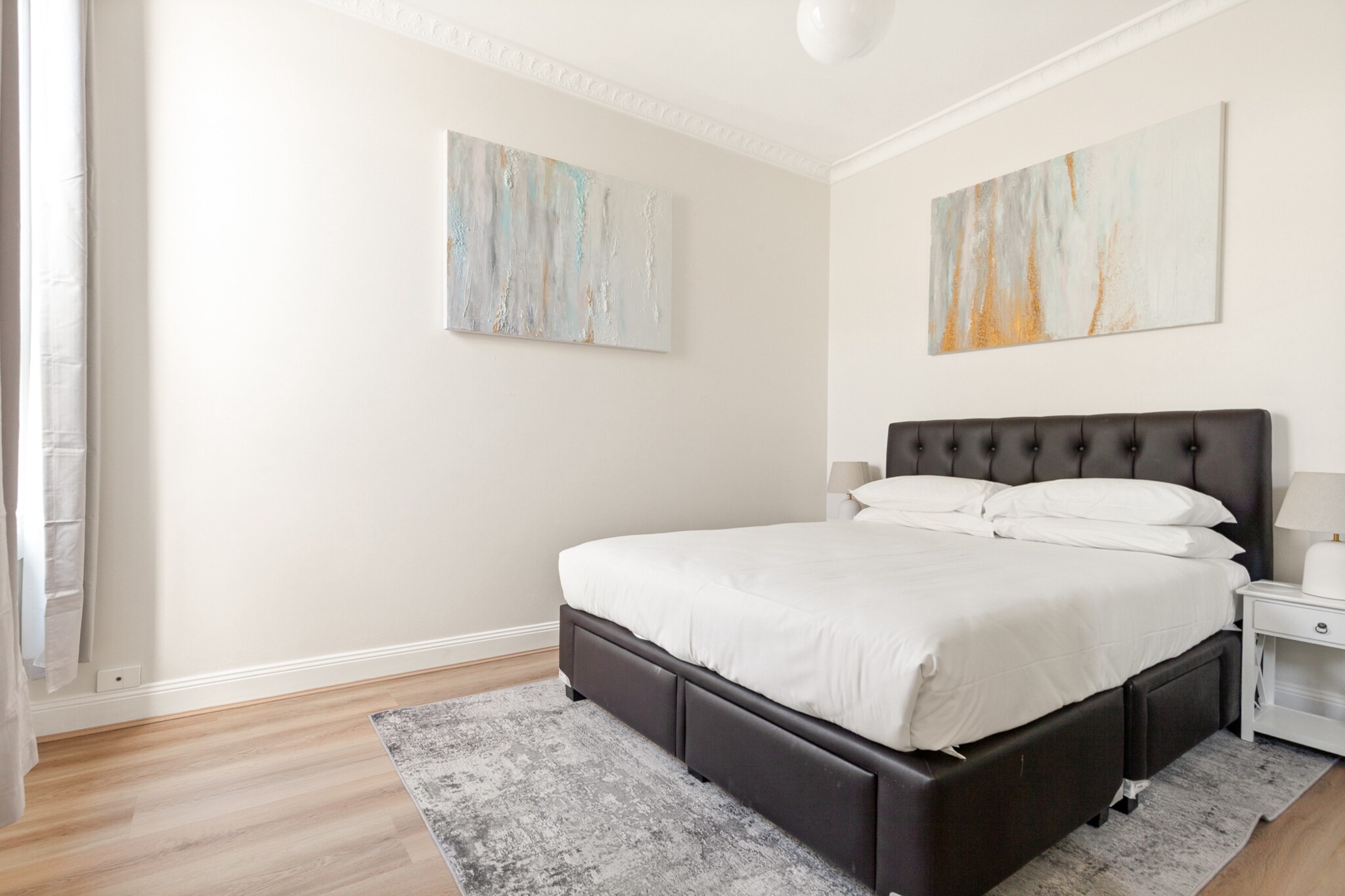 Enjoy a spacious stay in this bright 2-bedroom, 1-bath house in Leichhardt, offering a private courtyard, stylish interiors, and a fully equipped kitchen. Perfect for families or small groups, it includes a comfortable lounge, a dedicated dining area, a private laundry, and split A/C. Just moments from vibrant Norton Street, this property is ideal for a relaxed Sydney getaway with self-check-in.

The space
Step into a bright and welcoming 2-bedroom home nestled in the heart of Leichhardt. This freestanding house opens with a charming street entrance. Inside, the two bedrooms offer a restful atmosphere with two queen beds, bedside tables, and warm lighting. The bathroom is neatly appointed and includes essentials for a comfortable stay. The living room features wood flooring, plush couches - one of which converts into a pull-down style sofa bed, a stylish rug, and a TV for entertainment. The fully equipped kitchen offers an electric stovetop and oven, dishwasher, and coffee machine, ideal for preparing meals with ease. A dining table comfortably seats six guests, perfect for shared meals. A private laundry area is included, with a washer, dryer, and a starter pack of cleaning amenities. Outside, the property features direct access to a private courtyard via the laundry or dining room, ideal for a breath of fresh air. This lovely home combines comfort with practicality in a location steps from Leichhardtâ€™s cultural and dining highlights, making it a wonderful choice for your next Sydney stay.
 
Living Room
- Couch seats 3 people + 2 armchairs
- TV with Free-to-Air
- Couch converts to a queen sofa bed (2 additional guests)
 
Kitchen & Dining Area
- Fully equipped with cutlery and utensils
- Electric oven and electric stovetop
- Dining area seats 6
 
Bathroom & Laundry
- Laundry room available with washer and dryer
- Travel essentials, towels and hairdryer provided
 
Amenity Notes
- Parking is Available with Garage clickers being placed in the House
- Split A/C (heating + cooling) in the living room only
- 2 portable heaters available
- Wi-Fi is available
- Front courtyard with seating
- Back garden access via the dining area
Local area description
Located in the heart of Leichhardt, this home is a short walk from Norton Streetâ€™s Italian eateries, cafÃ©s, and boutique shops. Enjoy the nearby Palace Cinemas, stroll through Pioneers Memorial Park, or explore the vibrant Inner West culture. Ideal for guests seeking a relaxed, village-style atmosphere within reach of the Sydney CBD.
House rules
You are staying in a friendly and peaceful neighbourhood and we kindly ask you to respect the community and your surrounding neighbours. The following strict House Rules apply:
 
- No loud noise between 10 pm and 8 am
- No parties or antisocial behaviour
- No additional people are to access the property without our prior approval
- No pets are allowed in the property without approval
- No smoking is allowed at any times
- If you break something, please let us know
- To help protect all floor coverings, do not wear any shoes inside the property
 
Please be aware that excessive noise such as amplified music, vocals or screaming or anti-social behaviour in the property or common areas can cause neighbours to complain to us, the Building Manager, Council Rangers or Police.
 
IMPORTANT:
- Any breach of the House Rules may lead to a $500 fine plus compensation for any cost/damage created and immediate eviction of the property without refund.
- Pets are available on request unless the property states it is pet friendly. Any stays with pets will incur an additional cleaning fee of $200.
 
Finally, when checking out, we kindly ask you for the following:
 
- Please leave all beds unmade
- Please clean up your dishes and put them away
- In case you have rearranged furniture, please put it back to the original location
- Please take out the rubbish and remember to use the right bins
- Please ensure all appliances, A/C and lights are off and doors and windows are closed.
- Please check your accommodation thoroughly before departing to avoid any unintentional items left behind.
 
We are not liable for any items left behind after your stay. In the rare event that a guest reports a missing item, we will make every effort to locate it for you, but we cannot guarantee its retrieval. If the item is found, we will gladly assist in arranging its return to an address within Australia, subject to postage and service fees.
Interaction with guests
Welcome to MadeComfy! Our local team curates stays in exceptional Australian & New Zealand properties, ensuring style, comfort, and prime locations for discerning guests. We prioritise your needs to provide a memorable home-away-from-home experience. Explore our digital guidebooks for local recommendations, and don't hesitate to contact us throughout your stay. We're here to ensure your comfort - enjoy your stay with MadeComfy.
Notes
- Stairs are required to access the property
 
For your comfort, this property is prepared with professional-grade hotel-style linen, including a three-sheet setup, ensuring a fresh and hygienic sleep experience.
 
Extra Services:
- Early Check-in: Our standard check-in is at 3 pm. To guarantee early access to the property we suggest booking the night before if available. Otherwise, early check-in is subject to availability from the night before at an additional cost.
- Late check-out: Our standard check-out is at 10 am. To guarantee a later check-out of the property we suggest booking an additional night if available. Otherwise, a late check-out is subject to availability from the night before to an additional cost.
- Baggage: For security reasons, we are unable to receive or to keep unattended baggage before check-in or after check-out
- We provide a small welcome amenity pack to get your stay started.
- This booking is protected with coverage for lost baggage and emergency medical expenses, provided by Travel Support with claim upto 500 AUD (T&C Applies). For more details reach out to Guest Support team post booking.
Access description
Key collection is onsite. Further details will be provided 3 days before check-in if your booking is successfully reserved.
Getting around
Public Transport:
Buses run frequently along Norton St and Parramatta Rd. Petersham and Lewisham train stations are approx. 15 min walk.
 
Getting There:
Approx. 25 mins by car from Sydney Airport and 20 mins from Sydney CBD.