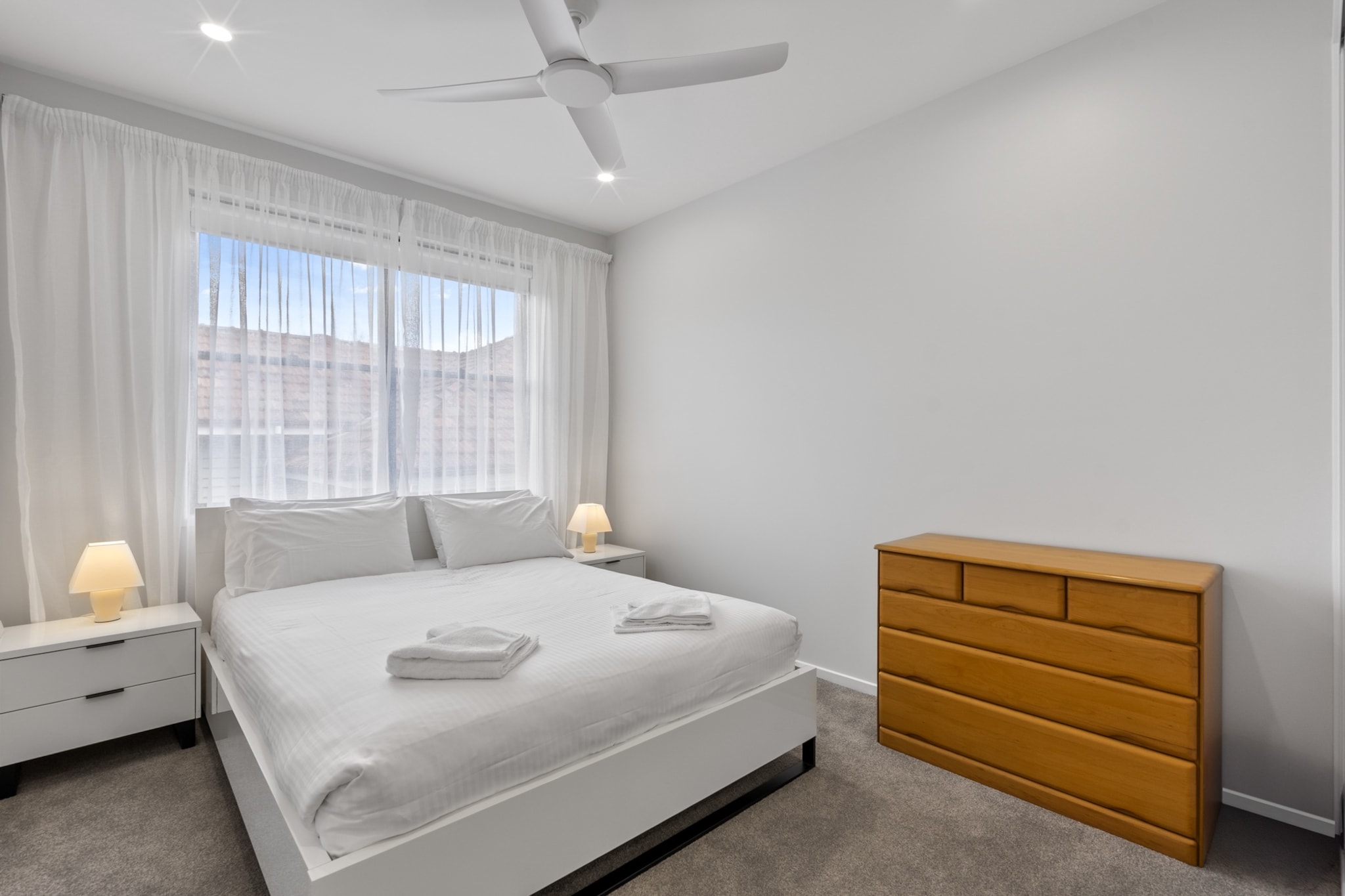 This bright and stylish 3-bedroom Clayfield home features a private garden patio, a dedicated study nook, and thoughtfully designed interiors across two spacious levels. Enjoy multiple living areas, a fully equipped kitchen, ducted air conditioning, and secure driveway parking. Unwind with streaming-ready TVs or fire up the BBQ outdoors. Perfect for families or groups, with easy self-check-in.
The space
Spread over two levels, this bright and airy Clayfield house blends comfort and style in a spacious layout perfect for families or group stays. Downstairs, the open-plan living and dining area flows seamlessly into a fully equipped kitchen fitted with modern appliances. Upstairs, find a cosy second lounge for added relaxation and access to three serene bedrooms. Two feature queen-sized beds with soft furnishings and ample storage, while a third includes a trundle bed with king single mattresses, ideal for kids or extra guests. The master bedroom boasts an en-suite and a quiet study nook by the sliding doorsâ€”perfect for remote work. The bathrooms are modern, and the laundry includes both a washer and dryer for added convenience. Outside, a private patio with a BBQ and full outdoor furniture invites leisurely meals in the Queensland sun, surrounded by a neat garden. With ducted A/C throughout and ceiling fans in all rooms, comfort is ensured year-round.
 
Living Room
- Couch seats 4 people
- TV with Free-to-Air and streaming (guests to use their own credentials)
 
Kitchen & Dining Area
- Fully equipped with cutlery and utensils
- Electric oven and induction stovetop
- Dining area seats 6 and countertop seats 3
 
Bathroom & Laundry
- Laundry room available with washer and dryer
- Travel essentials, towels and hairdryer provided
 
Amenity Notes
- Outdoor seating for 6 people
- Parking: Onsite driveway parking for 1 car (4m x 3m)
- Ducted A/C (heating + cooling) throughout
- Wi-Fi is available
- Study nook in master bedroom
- Private amenities: Front garden and patio with BBQ
Local area description
Set in leafy Clayfield, this home offers a peaceful base close to Brisbane's vibrant inner north. Enjoy local cafÃ©s, shops, and parks, or take a short drive to Eagle Farm Racecourse, Portside Wharf dining precinct, and the Brisbane Riverwalk. Ideal for families and professionals seeking easy access to the city and surrounding suburbs.
House rules
You are staying in a friendly and peaceful neighbourhood and we kindly ask you to respect the community and your surrounding neighbours. The following strict House Rules apply:
 
- No loud noise between 10 pm and 8 am
- No parties or antisocial behaviour
- No additional people are to access the property without our prior approval
- No pets are allowed in the property without approval
- No smoking is allowed at any times
- If you break something, please let us know
- To help protect all floor coverings, do not wear any shoes inside the property
 
Please be aware that excessive noise such as amplified music, vocals or screaming or anti-social behaviour in the property or common areas can cause neighbours to complain to us, the Building Manager, Council Rangers or Police.
 
IMPORTANT:
- Any breach of the House Rules may lead to a $500 fine plus compensation for any cost/damage created and immediate eviction of the property without refund.
- Pets are available on request unless the property states it is pet friendly. Any stays with pets will incur an additional cleaning fee of $200.
 
Finally, when checking out, we kindly ask you for the following:
 
- Please leave all beds unmade
- Please clean up your dishes and put them away
- In case you have rearranged furniture, please put it back to the original location
- Please take out the rubbish and remember to use the right bins
- Please ensure all appliances, A/C and lights are off and doors and windows are closed.
- Please check your accommodation thoroughly before departing to avoid any unintentional items left behind.
 
We are not liable for any items left behind after your stay. In the rare event that a guest reports a missing item, we will make every effort to locate it for you, but we cannot guarantee its retrieval. If the item is found, we will gladly assist in arranging its return to an address within Australia, subject to postage and service fees.
Interaction with guests
Welcome to MadeComfy! Our local team curates stays in exceptional Australian & New Zealand properties, ensuring style, comfort, and prime locations for discerning guests. We prioritise your needs to provide a memorable home-away-from-home experience. Explore our digital guidebooks for local recommendations, and don't hesitate to contact us throughout your stay. We're here to ensure your comfort - enjoy your stay with MadeComfy.
Notes
- Stairs inside the property
- Guest is not to use the garage
- The modem must remain on the main bedroom window ledge
- BBQ to be moved away from the house when used
- Bins to be placed out Tuesday evenings
 
For your comfort, this property is prepared with professional-grade hotel-style linen, including a three-sheet setup, ensuring a fresh and hygienic sleep experience.
 
Extra Services:
- Early Check-in: Our standard check-in is at 3 pm. To guarantee early access to the property we suggest booking the night before if available. Otherwise, early check-in is subject to availability from the night before at an additional cost.
- Late check-out: Our standard check-out is at 10 am. To guarantee a later check-out of the property we suggest booking an additional night if available. Otherwise, a late check-out is subject to availability from the night before to an additional cost.
- Baggage: For security reasons, we are unable to receive or to keep unattended baggage before check-in or after check-out
- We provide a small welcome amenity pack to get your stay started.
- This booking is protected with coverage for lost baggage and emergency medical expenses, provided by Travel Support with claim upto 500 AUD (T&C Applies). For more details reach out to Guest Support team post booking.
Access description
Key collection is onsite. Further details will be provided 3 days before check-in if your booking is successfully reserved.
Getting around
Public Transport
Clayfield Station (700m) offers access to Brisbane CBD via the Doomben line. Bus stops along Sandgate Rd provide easy north/south connections.
 
Getting There
Brisbane Airport is approx. 10 mins (6km) by car. Brisbane CBD is approx. 15 mins (7.5km) drive.