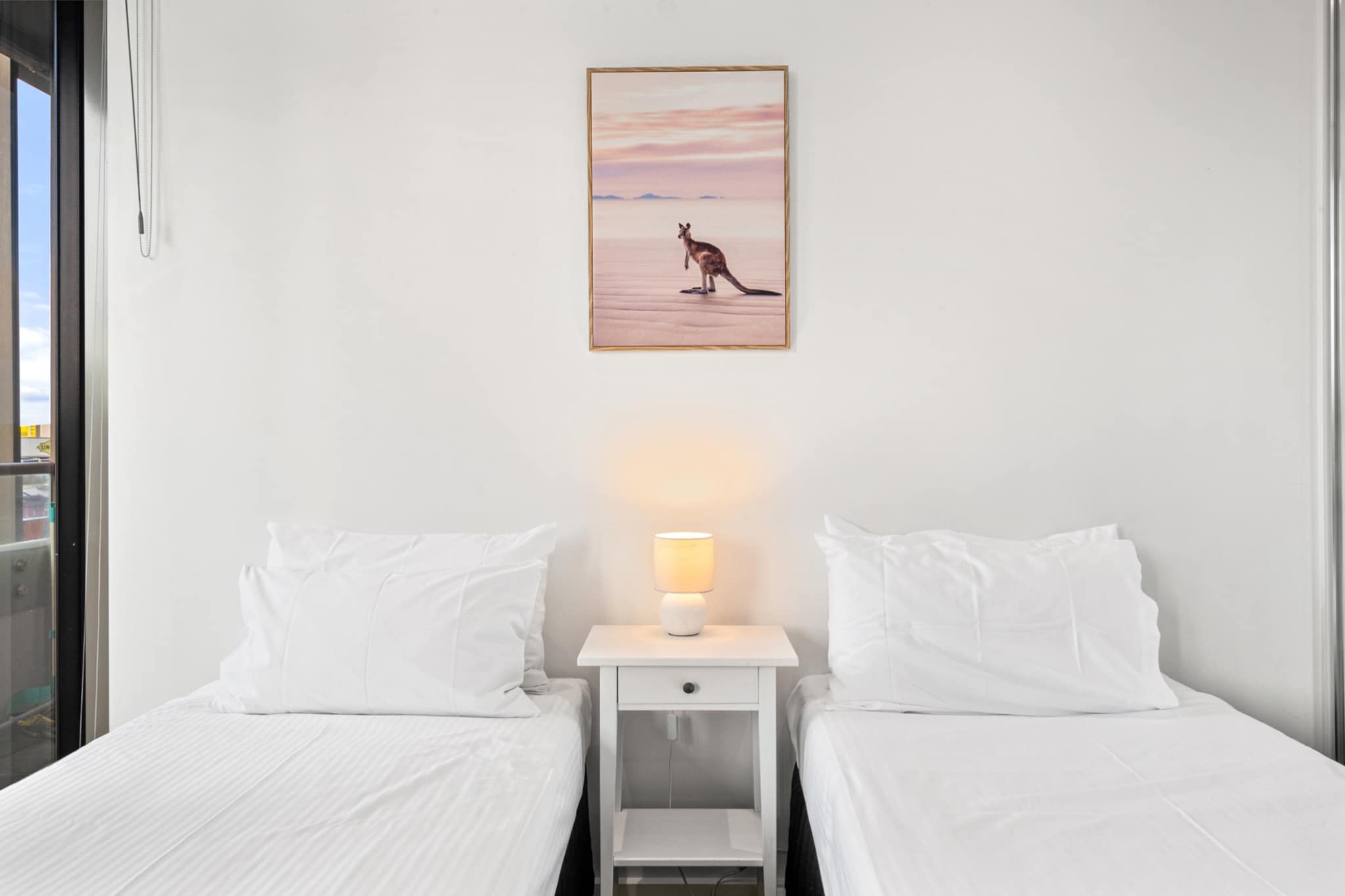 The property is close proximity to the MCG, Albert Park, and Marvel Stadium, the apartment features a fully equipped kitchen, washing machine/dryer, and self check-in for your convenience, this epic family-friendly apartment with portacot, highchair, stroller and a dedicated WFH space. Enjoy a balcony with views, FREE secure parking, and access to an indoor heated pool, gym and tennis court.
The space
A lovely, light-filled apartment set in the heart of Southbank, this two-bedroom retreat offers comfort, style and convenience. Both bedrooms are generously sized, with a queen-size bed in the master and twin single beds in the second room, each dressed in quality linen to ensure a restful night's sleep. Thoughtfully designed for families, it includes a portacot, highchair and stroller, plus all essential amenities for a seamless stay.
 
The open-plan living space flows into a private balcony with elevated views, ideal for morning coffee or evening unwinding. A large dining area seats eight, while the fully equipped kitchen boasts an electric oven, induction cooktop, dishwasher and coffee machine. A dedicated work-from-home space makes it ideal for business travellers or digital nomads.
 
Two sleek bathrooms, including an en-suite, plus a private laundry with washer and dryer, add practicality to the stylish surroundings. Guests enjoy FREE secure parking and access to building facilities including an indoor heated pool, gym and tennis court. Whether you're travelling for work, family or leisure, this apartment provides a welcoming home base in a prime location near to the MCG, Albert Park, and Marvel Stadium.
 
Living Room
- Couch seats 7 people
- TV with Free-to-Air and streaming
 
Kitchen & Dining Area
- Fully equipped with cutlery, and utensils
- Electric stovetop and electric oven
- Dining area seats 8
 
Bathroom & Laundry
- Laundry room available with washer and dryer
- Travel essentials, towels and hairdryer provided
 
Amenity Notes
- Secured parking for 1 vehicle
- Wi-Fi is available
- Air conditioning in living and master bedroom
- Private balcony accessed from living area
- Dedicated WFH space
- Building amenities: Indoor heated pool, GYM at level 7, Tennis court
Local area description
Southbank is Melbourneâ€™s vibrant riverside hub, known for its striking skyline, arts venues, and foodie hotspots. Wander to the National Gallery of Victoria, enjoy shows at Arts Centre Melbourne, or stroll along Southbank Promenade. Nearby MCG, Albert Park, Marvel Stadium and Federation Square add cultural and entertainment flair. Perfect for exploring the best of city life.
House rules
You are staying in a friendly and peaceful neighbourhood and we kindly ask you to respect the community and your surrounding neighbours. The following strict House Rules apply:
 
- No loud noise between 10 pm and 8 am
- No parties or antisocial behaviour
- No additional people are to access the property without our prior approval
- No pets are allowed in the property without approval
- No smoking is allowed at any times
- If you break something, please let us know
- To help protect all floor coverings, do not wear any shoes inside the property
 
Please be aware that excessive noise such as amplified music, vocals or screaming or anti-social behaviour in the property or common areas can cause neighbours to complain to us, the Building Manager, Council Rangers or Police.
 
IMPORTANT:
- Any breach of the House Rules may lead to a $500 fine plus compensation for any cost/damage created and immediate eviction of the property without refund.
- Pets are available on request unless the property states it is pet friendly. Any stays with pets will incur an additional cleaning fee of $200.
 
Finally, when checking out, we kindly ask you for the following:
 
- Please leave all beds unmade
- Please clean up your dishes and put them away
- In case you have rearranged furniture, please put it back to the original location
- Please take out the rubbish and remember to use the right bins
- Please ensure all appliances, A/C and lights are off and doors and windows are closed.
- Please check your accommodation thoroughly before departing to avoid any unintentional items left behind.
 
We are not liable for any items left behind after your stay. In the rare event that a guest reports a missing item, we will make every effort to locate it for you, but we cannot guarantee its retrieval. If the item is found, we will gladly assist in arranging its return to an address within Australia, subject to postage and service fees.
Interaction with guests
Welcome to MadeComfy! Our local team curates stays in exceptional Australian & New Zealand properties, ensuring style, comfort, and prime locations for discerning guests. We prioritise your needs to provide a memorable home-away-from-home experience. Explore our digital guidebooks for local recommendations, and don't hesitate to contact us throughout your stay. We're here to ensure your comfort - enjoy your stay with MadeComfy.
Notes
For your comfort, this property is prepared with professional-grade hotel-style linen, including a three-sheet setup, ensuring a fresh and hygienic sleep experience.
 
Extra Services:
- Early Check-in: Our standard check-in is at 3 pm. To guarantee early access to the property we suggest booking the night before if available. Otherwise, early check-in is subject to availability from the night before at an additional cost.
- Late check-out: Our standard check-out is at 10 am. To guarantee a later check-out of the property we suggest booking an additional night if available. Otherwise, a late check-out is subject to availability from the night before to an additional cost.
- Baggage: For security reasons, we are unable to receive or to keep unattended baggage before check-in or after check-out
- We provide a small welcome amenity pack to get your stay started.
- This booking is protected with coverage for lost baggage and emergency medical expenses, provided by Travel Support with claim upto 500 AUD (T&C Applies). For more details reach out to Guest Support team post booking.
Access description
Further details will be provided 3 days before check-in if your booking is successfully reserved.
Getting around
Public Transport:
Trams along St Kilda Rd and multiple bus stops are within 5 min walk. Flinders St Station is approx. 10 min away.
 
Getting There:
Melbourne Airport is approx. 25 km (30 min drive). Melbourne CBD is just 2 km away (10 min drive or tram).