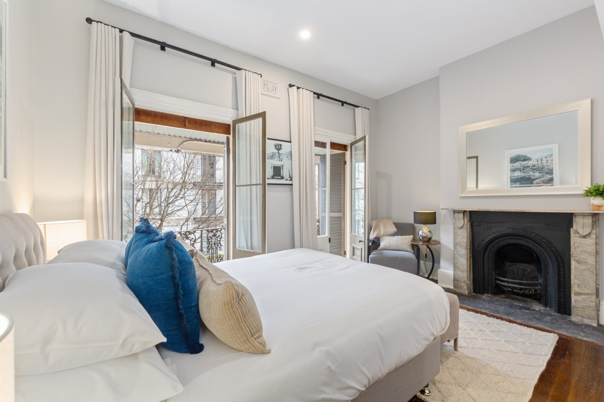 Enjoy a spacious stay in this four-bedroom heritage house in the heart of Millers Point. With stylish interiors, multiple bathrooms, and inviting outdoor areas, it's perfect for families or groups. Set near Barangaroo and The Rocks, explore the harbour, historic streets, and vibrant dining scenes. Includes self-check-in via digital lock for convenience.
The space
Set within Sydneyâ€™s historic Millers Point, this grand four-bedroom house offers timeless character blended with contemporary comforts. Polished wooden floors and modern furnishings flow through a spacious living area with an eight-seat couch and entertainment-ready TV. A formal dining space, seating eight, is complemented by a fully equipped kitchen boasting gas stovetop, electric oven, and coffee machine. Upstairs, a loft king bedroom and three additional bedrooms â€“ including queen and king single beds â€“ provide restful retreats, each fitted with blackout blinds and premium bedding. The home features three bathrooms, two of which are ensuites, ensuring comfort and privacy for all. Outside, unwind on the master bedroom balcony or enjoy the private backyard â€“ complete with outdoor furniture for comfortable seating â€“ accessed via sliding doors from the kitchen. Ideal for families or professionals, this charming residence offers generous space and serene surroundings in a sought-after harbourside location.
 
Living Room
- Couch seats 8 people
- TV with digital platforms (guests to use their own credentials)
 
Kitchen & Dining Area
- Fully equipped with cutlery and utensils
- Electric oven and gas stovetop
- Dining area seats 8 and countertop seats 4
 
Bathroom & Laundry
- Laundry room available with washer and dryer
- Travel essentials, towels and hairdryer provided
 
Amenity Notes
- Parking: 2-hour ticketed street parking available nearby
- Ducted A/C (heating + cooling) throughout (excluding single beds room)
- Split system A/C in kitchen
- 1x portable heater and fan for single beds room
- Wi-Fi is available
- The fireplace is for decoration purposes only
- Private outdoor areas: balcony and backyard with full outdoor furniture
Local area description
Millers Point blends heritage charm with city convenience. Enjoy walks to Barangaroo Reserve, harbourside dining at The Rocks, and cultural attractions like the Museum of Contemporary Art. The historic setting offers leafy streets and water views, all minutes from Sydneyâ€™s CBD.
House rules
You are staying in a friendly and peaceful neighbourhood and we kindly ask you to respect the community and your surrounding neighbours. The following strict House Rules apply:
 
- No loud noise between 10 pm and 8 am
- No parties or antisocial behaviour
- No additional people are to access the property without our prior approval
- No pets are allowed in the property without approval
- No smoking is allowed at any times
- If you break something, please let us know
- To help protect all floor coverings, do not wear any shoes inside the property
 
Please be aware that excessive noise such as amplified music, vocals or screaming or anti-social behaviour in the property or common areas can cause neighbours to complain to us, the Building Manager, Council Rangers or Police.
 
IMPORTANT:
- Any breach of the House Rules may lead to a $500 fine plus compensation for any cost/damage created and immediate eviction of the property without refund.
- Pets are available on request unless the property states it is pet friendly. Any stays with pets will incur an additional cleaning fee of $200.
 
Finally, when checking out, we kindly ask you for the following:
 
- Please leave all beds unmade
- Please clean up your dishes and put them away
- In case you have rearranged furniture, please put it back to the original location
- Please take out the rubbish and remember to use the right bins
- Please ensure all appliances, A/C and lights are off and doors and windows are closed.
- Please check your accommodation thoroughly before departing to avoid any unintentional items left behind.
 
We are not liable for any items left behind after your stay. In the rare event that a guest reports a missing item, we will make every effort to locate it for you, but we cannot guarantee its retrieval. If the item is found, we will gladly assist in arranging its return to an address within Australia, subject to postage and service fees.
Interaction with guests
Welcome to MadeComfy! Our local team curates stays in exceptional Australian & New Zealand properties, ensuring style, comfort, and prime locations for discerning guests. We prioritise your needs to provide a memorable home-away-from-home experience. Explore our digital guidebooks for local recommendations, and don't hesitate to contact us throughout your stay. We're here to ensure your comfort - enjoy your stay with MadeComfy.
Notes
- Stairs inside the property
- There is one step stair at the entrance
- The property is not suitable for people with mobility conditions or older guests due to very steep internal stairs.
 
For your comfort, this property is prepared with professional-grade hotel-style linen, including a three-sheet setup, ensuring a fresh and hygienic sleep experience.
 
Extra Services:
- Early Check-in: Our standard check-in is at 3 pm. To guarantee early access to the property we suggest booking the night before if available. Otherwise, early check-in is subject to availability from the night before at an additional cost.
- Late check-out: Our standard check-out is at 10 am. To guarantee a later check-out of the property we suggest booking an additional night if available. Otherwise, a late check-out is subject to availability from the night before to an additional cost.
- Baggage: For security reasons, we are unable to receive or to keep unattended baggage before check-in or after check-out
- We provide a small welcome amenity pack to get your stay started.
- This booking is protected with coverage for lost baggage and emergency medical expenses, provided by Travel Support with claim upto 500 AUD (T&C Applies). For more details reach out to Guest Support team post booking.
Access description
Key collection is onsite. Further details will be provided 3 days before check-in if your booking is successfully reserved.
Getting around
Frequent buses run along Kent and Argyle Streets. Wynyard Station is just a 10-min walk, connecting to trains and the Sydney Light Rail.
 
Getting There
Sydney Airport is approx. 25 mins by car. Sydney CBD is under 10 mins by car or 15 mins on foot.