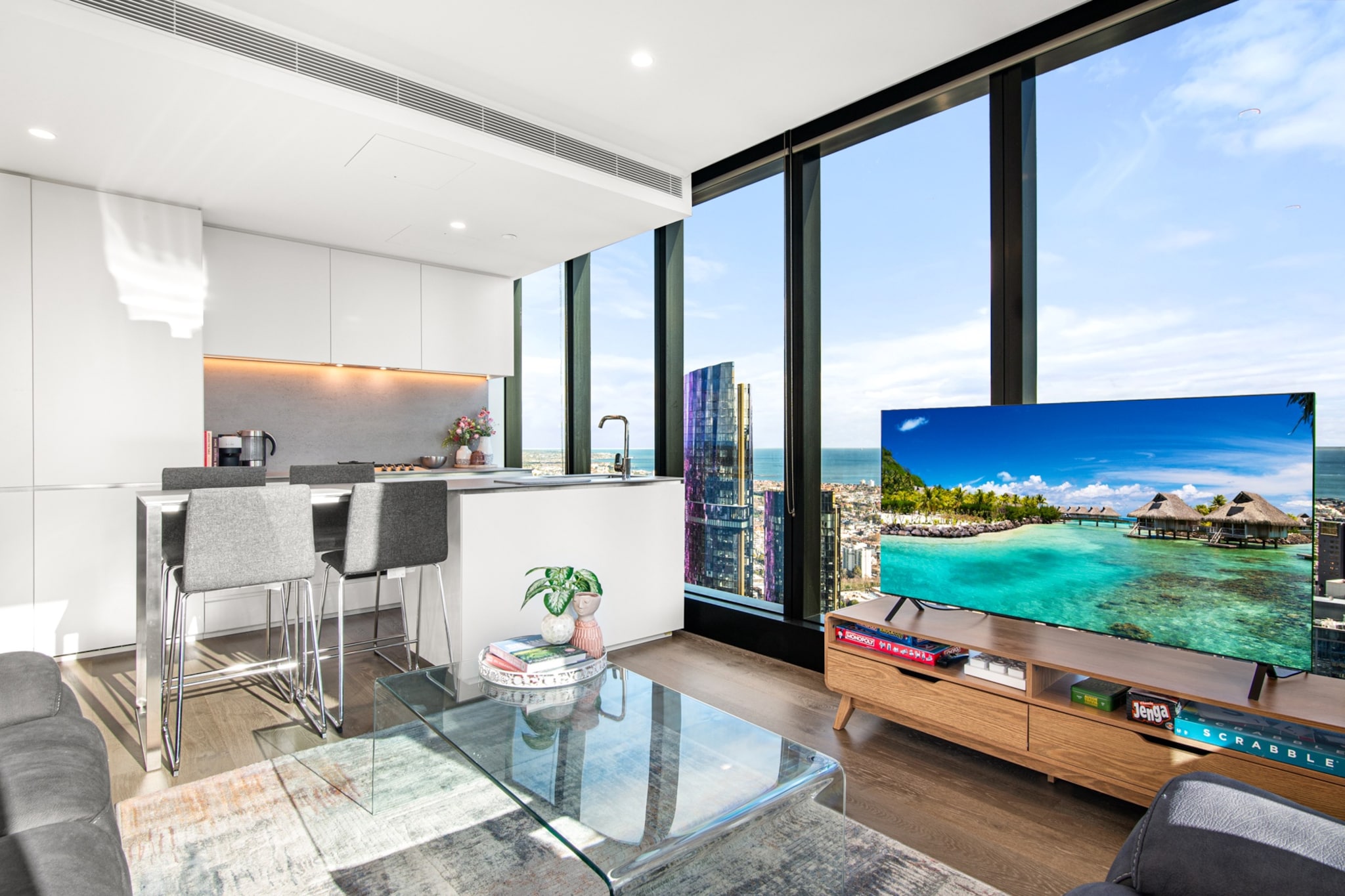 Enjoy a stylish city retreat in this elegant 2-bedroom Southbank apartment. Unwind in a bright open-plan space with sweeping city views and modern finishes. With a fully equipped kitchen, internal laundry, and self check-in, itâ€™s ideal for couples or solo travellers. Located near the Melbourne Arts Precinct and riverside dining, this is the perfect base to explore the city in comfort.
The space
Step into a sleek and thoughtfully styled city apartment in the heart of Southbank. The open-plan living space is filled with natural light and features a plush sofa, reclining armchair, and smart TV. Floor-to-ceiling windows frame sweeping views of the city skyline, creating the perfect setting for morning coffee or an evening wind-down.
 
The modern kitchen includes a ceramic cooktop, integrated oven, and all essential cookware, cutlery, and utensils. Share a meal at the dining area for four or grab a quick bite at the two-seat countertop.
 
Both bedrooms provide a quiet retreat, complete with comfortable beds and built-in wardrobes. The bathroom features contemporary fixtures and a glass-enclosed shower, while the internal laundry includes a washer and dryer for added convenience.
 
Designed for comfort and functionality, this stylish apartment offers a peaceful base with city vibrance just outside your door.
 
Living Room
- Sofa for 3 people plus reclining armchair
- TV with Free-to-Air (guests to use their own credentials)
 
Kitchen & Dining Area
- Fully equipped with cookware, cutlery, and utensils
- Oven and ceramic stovetop
- Dining area countertop seats 4
 
Bathroom & Laundry
- Laundry room available with washer and dryer
- Travel essentials, towels and hairdryer provided
 
Amenity Notes
- Onsite parking in secure garage
- Ducted A/C (heating + cooling) throughout
- Wi-Fi is available