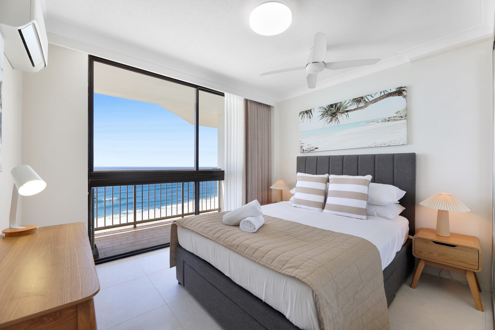 Enjoy a stylish beachfront escape at this modern 2-bedroom apartment in Surfers Paradise. With scenic ocean views, a private balcony, on-site parking, and access to a pool, tennis court, and BBQ area, itâ€™s ideal for families or couples. Features Wi-Fi, laundry, full kitchen, and onsite check-in for your convenience.
The space
Step inside this bright and welcoming 2-bedroom apartment, offering a seamless blend of comfort and style. The spacious open-plan living and dining area features tiled flooring, vibrant dÃ©cor, and two cosy 2-seater couches. Large sliding glass doors open onto a private balcony with outdoor seating, perfect for soaking up the ocean breeze. The fully equipped kitchen includes an electric oven, induction stovetop, dishwasher, and essential appliances for home-cooked meals. Each bedroom offers comfortable sleeping arrangementsâ€”one queen bed and two singlesâ€”alongside bedside tables, lamps, and ample storage. The master includes an ensuite, while a second bathroom ensures comfort for all guests. Enjoy the convenience of an internal laundry room, complete with washer, dryer, iron, and clothes rack. Guests also have access to on-site amenities including a pool, BBQ area, and tennis court.
 
Living Room
- 2 couches seating up to 4 people
- TV with Free-to-Air and streaming access (guests to use their own credentials)
 
Kitchen & Dining Area
- Fully equipped with cutlery and utensils
- Induction stovetop and electric oven
- Dining area seats 6 and countertop seats 4
 
Bathroom & Laundry
- Laundry room available with washer and dryer
- Travel essentials, towels and hairdryer provided
 
Amenity Notes
- On-site basement parking for 1 car
- Split system A/C (heating + cooling) throughout
- Ceiling fans in bedrooms and living room
- Wi-Fi is available
- Private Amenities: Balcony with outdoor furniture
- Building Amenities: Pool, tennis court, BBQ area (communal access via fob)
Local area description
Situated on the vibrant Esplanade, this apartment places you steps from the iconic Surfers Paradise Beach. Enjoy a range of dining, shopping and nightlife options all within walking distance. Nearby attractions include Sky Point Observation Deck, Cavill Avenue, and HOTA Gallery. A perfect location to embrace the Gold Coast lifestyle.
House rules
You are staying in a friendly and peaceful neighbourhood and we kindly ask you to respect the community and your surrounding neighbours. The following strict House Rules apply:
 
- No loud noise between 10 pm and 8 am
- No parties or antisocial behaviour
- No additional people are to access the property without our prior approval
- No pets are allowed in the property without approval
- No smoking is allowed at any times
- If you break something, please let us know
- To help protect all floor coverings, do not wear any shoes inside the property
 
Please be aware that excessive noise such as amplified music, vocals or screaming or anti-social behaviour in the property or common areas can cause neighbours to complain to us, the Building Manager, Council Rangers or Police.
 
IMPORTANT:
- Any breach of the House Rules may lead to a $500 fine plus compensation for any cost/damage created and immediate eviction of the property without refund.
- Pets are available on request unless the property states it is pet friendly. Any stays with pets will incur an additional cleaning fee of $200.
 
Finally, when checking out, we kindly ask you for the following:
 
- Please leave all beds unmade
- Please clean up your dishes and put them away
- In case you have rearranged furniture, please put it back to the original location
- Please take out the rubbish and remember to use the right bins
- Please ensure all appliances, A/C and lights are off and doors and windows are closed.
- Please check your accommodation thoroughly before departing to avoid any unintentional items left behind.
 
We are not liable for any items left behind after your stay. In the rare event that a guest reports a missing item, we will make every effort to locate it for you, but we cannot guarantee its retrieval. If the item is found, we will gladly assist in arranging its return to an address within Australia, subject to postage and service fees.
Interaction with guests
Welcome to MadeComfy! Our local team curates stays in exceptional Australian & New Zealand properties, ensuring style, comfort, and prime locations for discerning guests. We prioritise your needs to provide a memorable home-away-from-home experience. Explore our digital guidebooks for local recommendations, and don't hesitate to contact us throughout your stay. We're here to ensure your comfort - enjoy your stay with MadeComfy.
Notes
- Stairs to building entrance
 
For your comfort, this property is prepared with professional-grade hotel-style linen, including a three-sheet setup, ensuring a fresh and hygienic sleep experience.
 
Extra Services:
- Early Check-in: Our standard check-in is at 3 pm. To guarantee early access to the property we suggest booking the night before if available. Otherwise, early check-in is subject to availability from the night before at an additional cost.
- Late check-out: Our standard check-out is at 10 am. To guarantee a later check-out of the property we suggest booking an additional night if available. Otherwise, a late check-out is subject to availability from the night before to an additional cost.
- Baggage: For security reasons, we are unable to receive or to keep unattended baggage before check-in or after check-out
- We provide a small welcome amenity pack to get your stay started.
Access description
Key collection is onsite. Further details will be provided 3 days before check-in if your booking is successfully reserved.
Getting around
Public Transport
Surfers Paradise is serviced by G:link light rail with stops just minutes away. Local buses connect to Broadbeach, Southport and beyond.
 Getting There
Gold Coast Airport is approx. 35 mins by car. Brisbane CBD is approx. 1 hr 20 mins via M1.