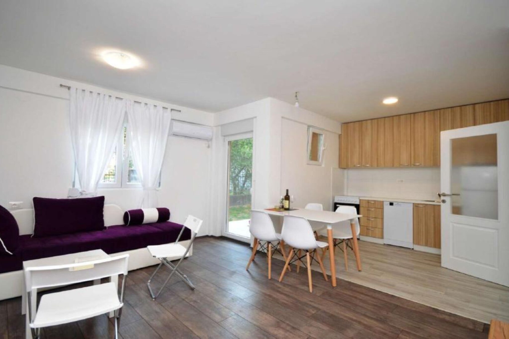 The "Adriatic Haven – Cozy Tivat Apartment with a Terrace" is a beachfront property located in Tivat, Montenegro. This apartment offers a private terrace with sea views, providing a serene environment for guests. It features a fully equipped kitchen, a flat-screen TV, and a washing machine. The property is also pet-friendly, allowing guests to bring their pets along. The apartment is situated approximately 2.3 miles from Porto Montenegro Marina and St. Sava Church. Tivat Airport is about 4.3 miles away, making it convenient for travelers.
Note:
Private parking is available, reservation is not required.
Wi-Fi is available throughout the property.
Pets are not  allowed .
Baby cot is available on request.
Baggage dropoff is available  Before checkin
This one-bedroom can accommodate up to four guests. It features a Flat screen TV and is combined with a living room and kitchen. The private bathroom is equipped with a shower and toilet.
Thanks to its excellent location, everything you'll need for your vacation is just a short walk away from the property. cafes and  restaurants—2.30 km.  The beach is 1.40  km away from the property.
The airport is 5 km away from the property.