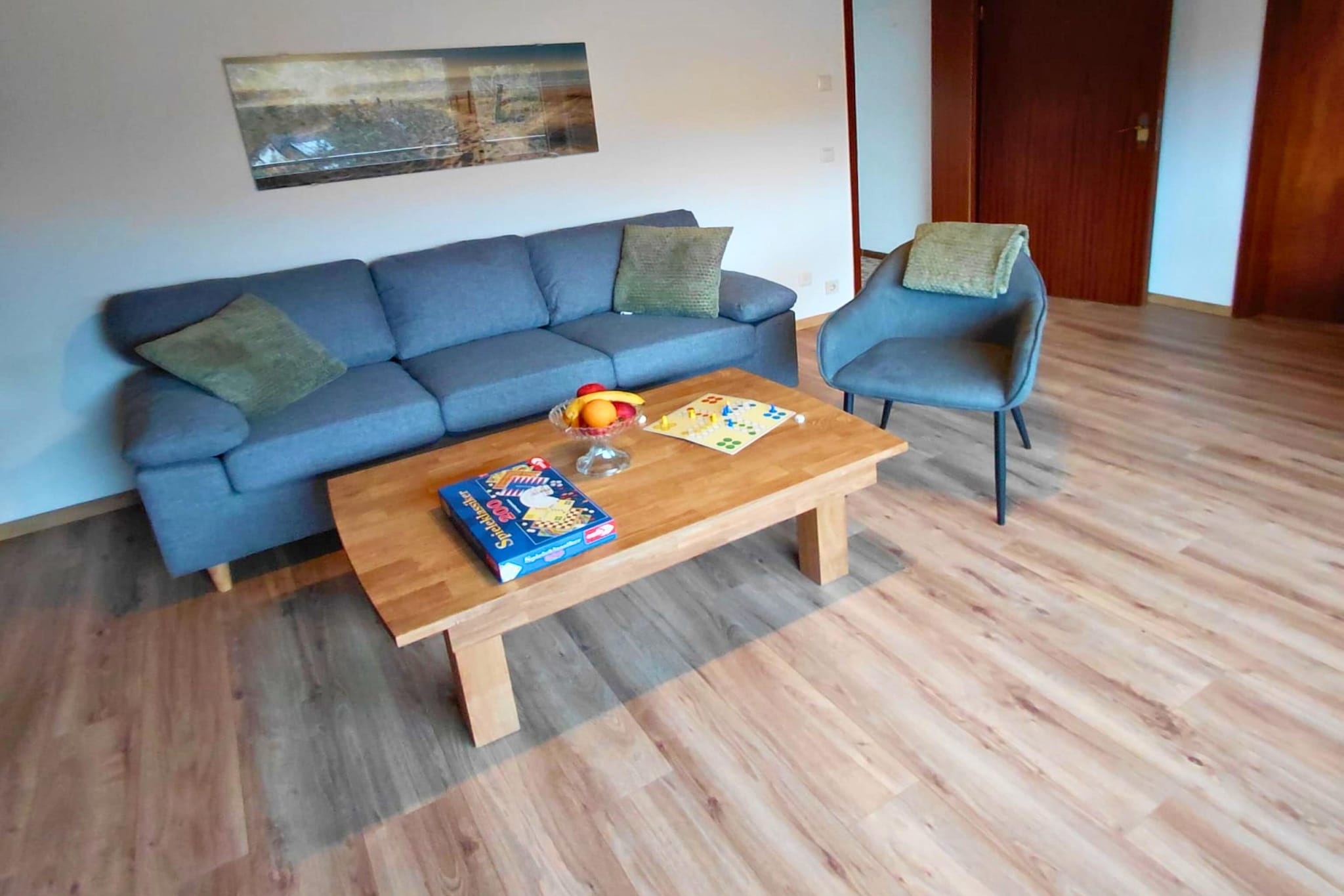 Living room(TV, seating area, balcony), Kitchen(electric kettle, toaster, coffee machine, oven, microwave, dishwasher, fridge), bedroom(double bed), bedroom(single bed), bathroom(shower, washbasin, toilet), washing machine, garden, garden furniture, parking, pond