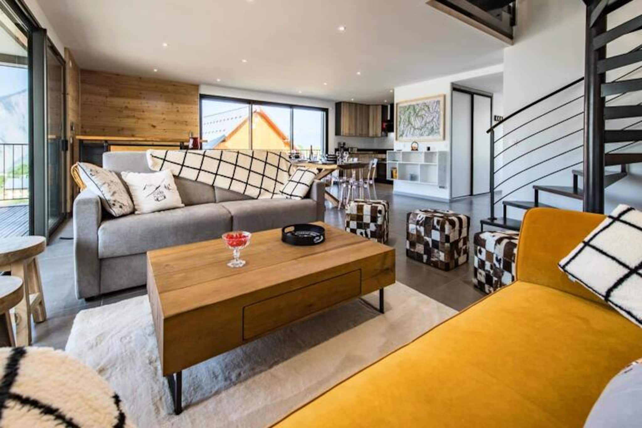 In the heart of the picturesque Albiez-Montrond, this stunning 123 m² triplex offers the perfect alpine escape for families and groups of friends. Imagine waking up to panoramic mountain views from your 27 m² wraparound balcony, where the crisp mountain air invigorates your senses. This modern and spacious retreat combines comfort with charm, offering ski-in/ski-out access (snow conditions permitting) for an unforgettable winter holiday or a serene summer getaway. 
 
 The triplex features a bright and airy living room, illuminated by two large bay windows that frame the breathtaking scenery. The open-plan layout includes a fully equipped kitchen with an oven, stovetop, refrigerator, and coffee maker, as well as a dining area with a large table perfect for shared meals. The cozy seating area invites you to relax after a day of adventure. With four beautifully appointed bedrooms, the property accommodates up to 13 guests. Two rooms feature queen-size beds, while the others offer single beds, including a charming room with four singles ideal for children. Three modern bathrooms, complete with a bathtub and showers, ensure convenience for all. 
 
 Located just 300 meters from the slopes and the ESF ski school, and a short stroll to Place de l'Opinel with its shops and restaurants, everything you need is within easy reach. Albiez-Montrond is a family-friendly resort with 35 km of varied slopes, making it perfect for both beginners and seasoned skiers. Beyond skiing, enjoy sledding, local dining, and the welcoming atmosphere of this charming village. 
 
 Whether you're seeking thrilling snow sports or tranquil mountain relaxation, this triplex is your gateway to the best of Albiez-Montrond. Book your stay today and create memories that will last a lifetime.