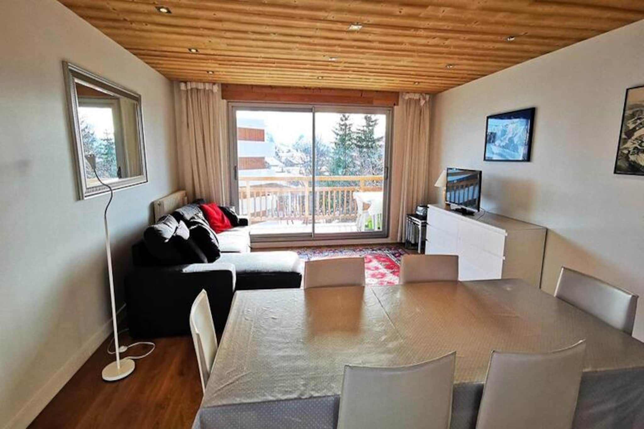 Bathed in sunlight and boasting a prime location, this beautifully renovated apartment offers a serene alpine escape just steps from the Rif Nel slope. Imagine waking up to the crisp mountain air, enjoying your morning coffee on the south-facing balcony, and heading straight to the Bergers ski lifts, only 50 meters away. Whether you’re here for winter sports or summer hikes, the vibrant atmosphere of the resort center is just a short stroll from your door, making this property the perfect base for your adventures. \n\nInside, the apartment is designed with comfort and practicality in mind. The spacious living room opens onto a balcony where you can soak in the views, and the open-plan kitchen is fully equipped with modern appliances, including an induction hob, oven, microwave, and dishwasher. The cozy bedroom features a double bed and bunk beds, making it ideal for families or small groups. A sleek bathroom with a bathtub and a separate toilet add to the convenience, while the ski locker ensures your gear is always ready for action. Please note, this is a non-smoking, pet-free property, and linens are not included.\n\nThe location couldn’t be better. With the Rif Nel slope and Bergers ski lifts practically at your doorstep, you’ll have effortless access to the slopes. The resort center offers a variety of dining, shopping, and entertainment options, ensuring your evenings are as enjoyable as your days. In summer, the area transforms into a haven for hikers and nature enthusiasts, with trails leading to breathtaking alpine vistas.\n\nWhether you’re seeking thrilling ski runs or tranquil mountain moments, this apartment combines modern comfort with unbeatable access to the best of the French Alps. Create unforgettable memories in this idyllic retreat.