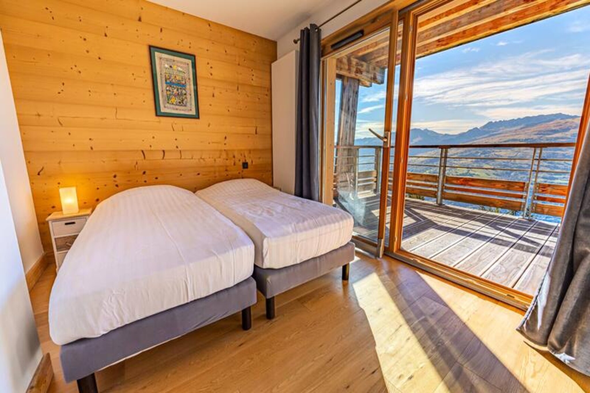 A true alpine gem awaits you in the heart of Les Arcs 1800, where breathtaking views of the Tarentaise Valley meet the comfort of a premium 4-star residence. This contemporary 72m² apartment, with its warm wood-inspired design, offers a serene retreat for up to six guests. Imagine waking up to the crisp mountain air, enjoying your morning coffee on the west-facing terrace, and planning a day filled with adventure or relaxation in this vibrant mountain village. Whether you're here for the snow-covered slopes or the lush summer trails, this property is your gateway to unforgettable memories. \n\nStep inside and discover a thoughtfully designed space featuring two bedrooms, a cozy sleeping alcove, and a bright open-plan living area. The fully equipped kitchen invites you to prepare delicious meals, while the comfortable lounge is perfect for unwinding after a day of exploration. Luxurious touches like hotel-quality linens, Wi-Fi, and a wellness area with a sauna, hammam, and fitness room ensure your stay is as relaxing as it is invigorating. The apartment also includes practical amenities such as a ski locker and bike storage, making it ideal for both winter and summer escapes. \n\nLocated in the lively Villards district, you're just a two-minute walk from ski schools, slopes, and a variety of shops and restaurants. In summer, the area transforms into a paradise for outdoor enthusiasts with mountain biking, hiking, climbing, and even paragliding opportunities nearby. The nearby aquatic center, treetop adventure park, and golf courses add to the endless activities available. \n\nWhether you're seeking thrilling adventures or peaceful moments surrounded by nature, this premium residence offers the perfect balance of luxury, convenience, and alpine charm. Let the majestic peaks of the French Alps be the backdrop to your next unforgettable holiday.