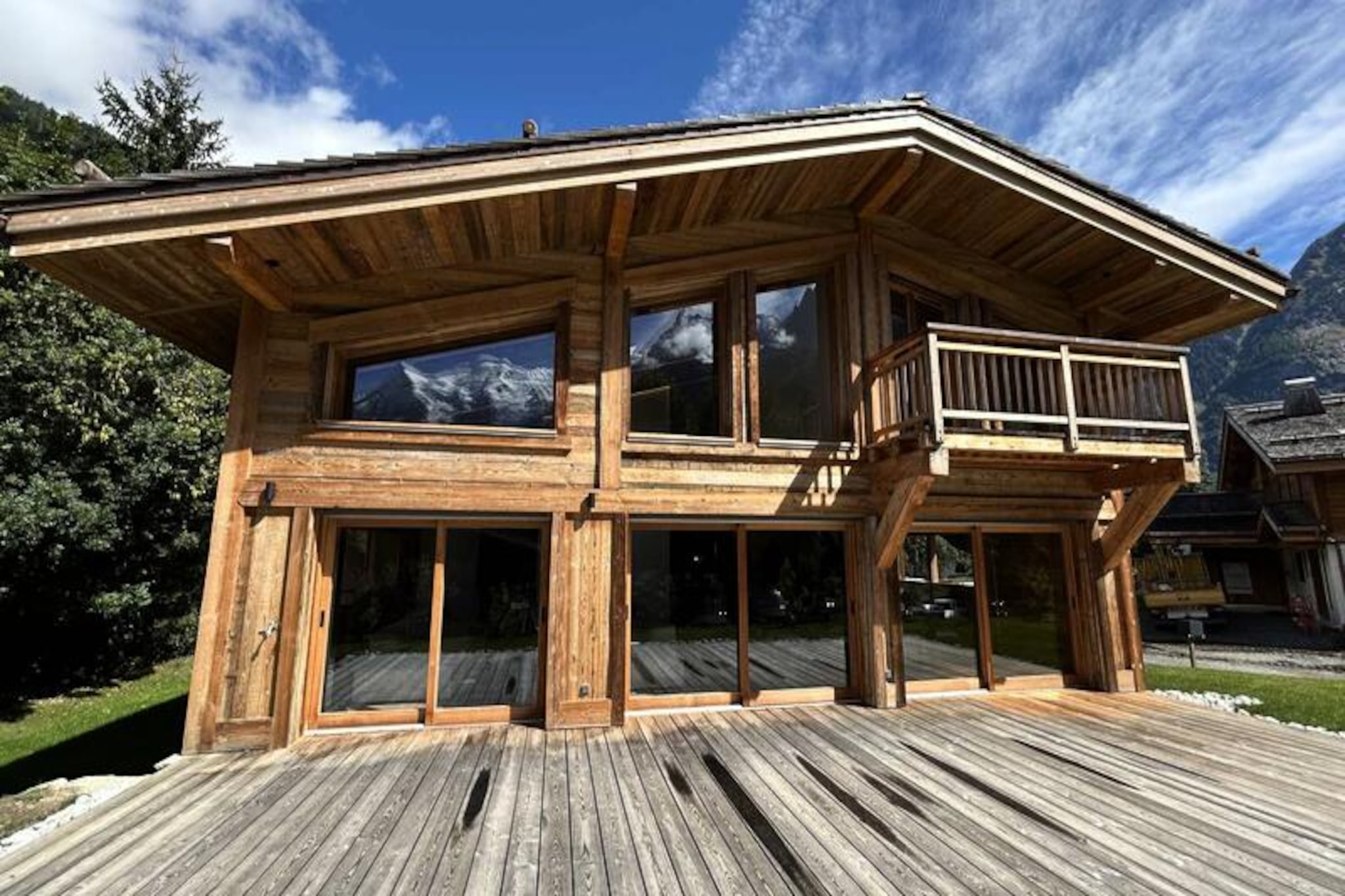 In the heart of the picturesque Les Praz plain, Chalet Black Rock invites you to immerse yourself in the serene beauty of the Alps. With breathtaking views of Mont Blanc, this luxurious retreat seamlessly blends traditional alpine charm with modern sophistication, creating an unforgettable haven for up to 10 guests. Whether you're seeking adventure or relaxation, this chalet offers the perfect balance of both. Picture yourself unwinding in the outdoor jacuzzi under a starlit sky or savoring a moment of tranquility in the private sauna after a day on the slopes.
The chalet's thoughtful layout spans three levels, ensuring comfort and privacy for all. The ground floor boasts a spacious open-plan living area with a cozy fireplace, a fully equipped kitchen, and a dining space for 10, all opening onto a terrace with panoramic mountain views. The master suite on this level features a plush double bed, en-suite dressing room, and a luxurious bathroom. Upstairs, three elegantly appointed bedrooms, each with its own en-suite facilities, offer restful retreats, while the lower level includes a bunk room, a TV lounge, and ample storage for ski and cycling gear.
Perfectly situated, Chalet Black Rock is just 1.2 km from the La Flégère cable car, offering easy access to world-class skiing and hiking trails. The charming village of Les Praz, with its shops, restaurants, and train station, is a short stroll away, while the vibrant town of Chamonix is only 3.1 km. Whether you're exploring the slopes or enjoying the chalet's high-end amenities, every moment here is steeped in alpine magic.
Choose Chalet Black Rock for your next mountain escape and experience the perfect blend of comfort, elegance, and adventure in the heart of the French Alps.