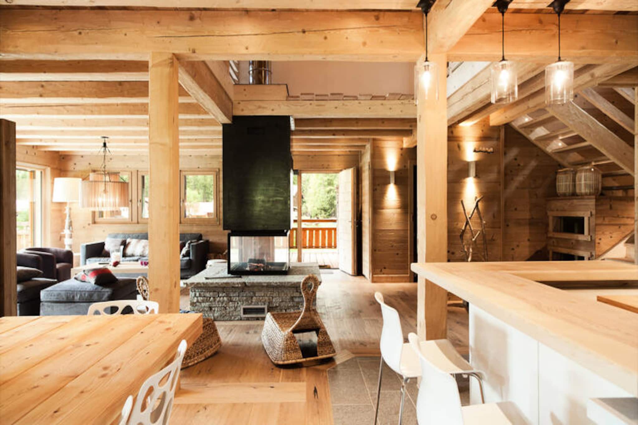 In the heart of the breathtaking Chamonix Valley, this magnificent 200m² chalet offers a luxurious retreat for up to 12 guests. Surrounded by the majestic peaks of the Mont Blanc massif, this property is just 1 km from the renowned Grands Montets ski area, making it a perfect base for winter sports enthusiasts and nature lovers alike. Whether you're here to carve through pristine slopes or explore the alpine trails, this chalet promises an unforgettable mountain escape.
Step inside and be greeted by a warm, inviting ambiance. The spacious living area features a central fireplace, perfect for cozy evenings after a day in the snow. The open-plan kitchen is fully equipped with modern appliances, including a steam oven, induction hob, and Nespresso coffee maker, ensuring every meal is a delight. Five beautifully appointed bedrooms, including en-suite options with private balconies, provide comfort and privacy for all guests. The dormitory, complete with bunk beds, TV, and DVD player, is ideal for younger travelers. Additional amenities such as a sauna, laundry facilities, and a terrace with garden furniture and a barbecue enhance your stay.
Located just 1.5 km from the charming village of Argentière and 8 km from Chamonix's vibrant center, you'll find a wealth of dining, shopping, and entertainment options nearby. Public transport is conveniently close, with a bus stop only 210m away and the Argentière train station just 1.8 km from the chalet. In summer, the region transforms into a haven for hikers, climbers, and cyclists, offering endless opportunities to explore the stunning alpine landscape.
Whether you're seeking adventure or relaxation, this chalet combines modern luxury with traditional alpine charm, making it the perfect choice for your next mountain getaway.