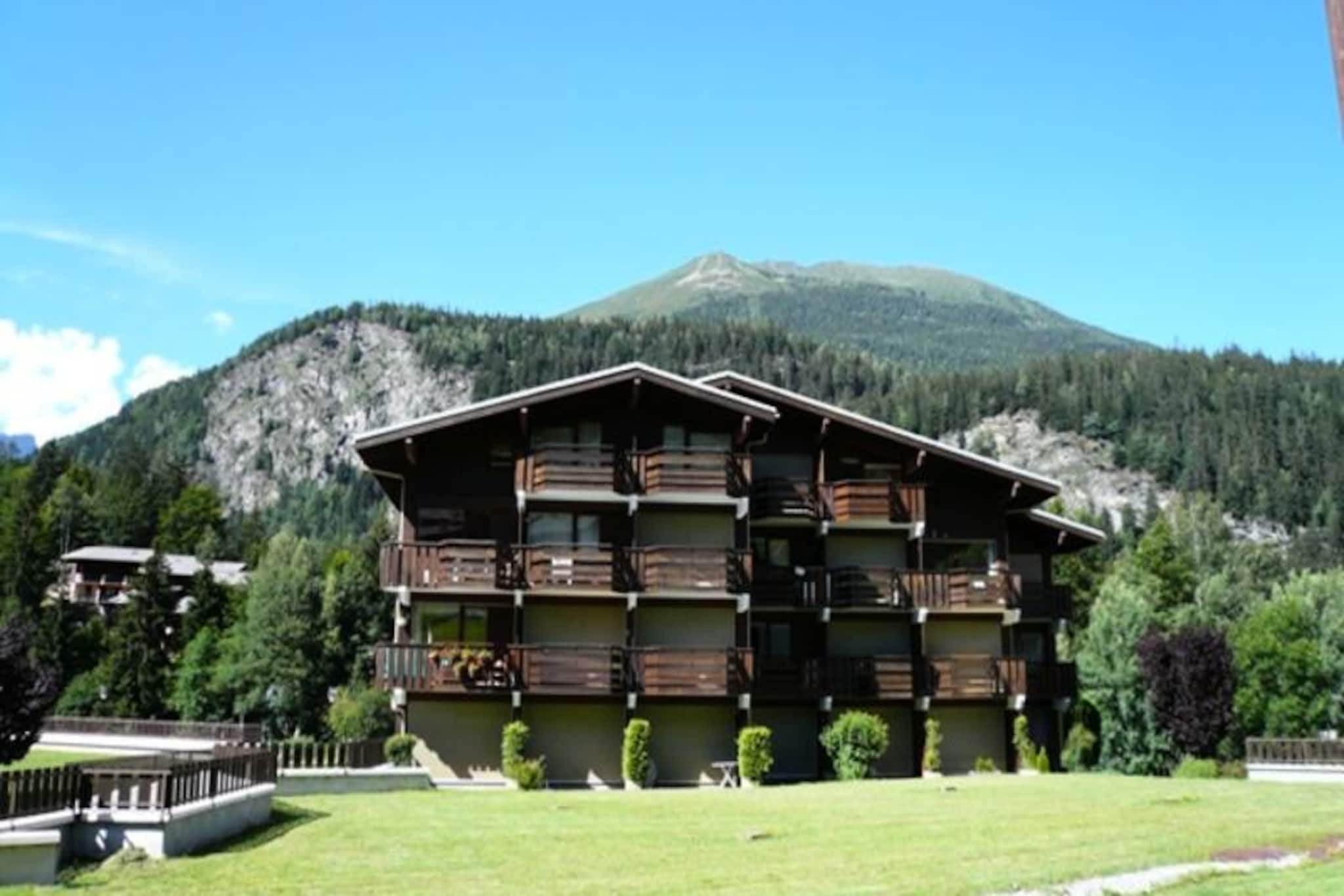 Where the majestic peaks of the French Alps meet serene southern exposure, this charming studio cabin in Les Houches invites you to experience mountain living at its finest. Just 120 meters from the Prarion cable cars, your alpine adventures begin moments from your doorstep. Whether you're seeking thrilling ski runs or tranquil hikes, this location offers the perfect blend of accessibility and natural beauty, with stunning views and crisp mountain air to awaken your senses each morning. \n\nDesigned for families or small groups, the 27m² studio comfortably accommodates up to four guests. The living room features a cozy sofa bed and dining area, while the kitchenette is equipped with essential appliances including electric burners, a refrigerator, and a microwave. A separate sleeping area with bunk beds ensures restful nights, and the bathroom with a bathtub provides a relaxing retreat after a day of outdoor activities. Additional conveniences such as an enclosed garage and outdoor parking make your stay hassle-free, while optional services like Wi-Fi and linen rentals add flexibility to your holiday plans. \n\nLes Houches offers a delightful mix of alpine charm and modern amenities. The village center, located just 1.5 km away, boasts restaurants, bars, a bakery, ski shops, and a Carrefour Contact for all your needs. In winter, enjoy direct access to pristine slopes, while summer brings opportunities for hiking, cycling, and exploring the breathtaking landscapes of the Chamonix Valley. \n\nWhether you're here to ski, relax, or simply immerse yourself in the beauty of the Alps, this studio cabin is your gateway to unforgettable mountain memories.