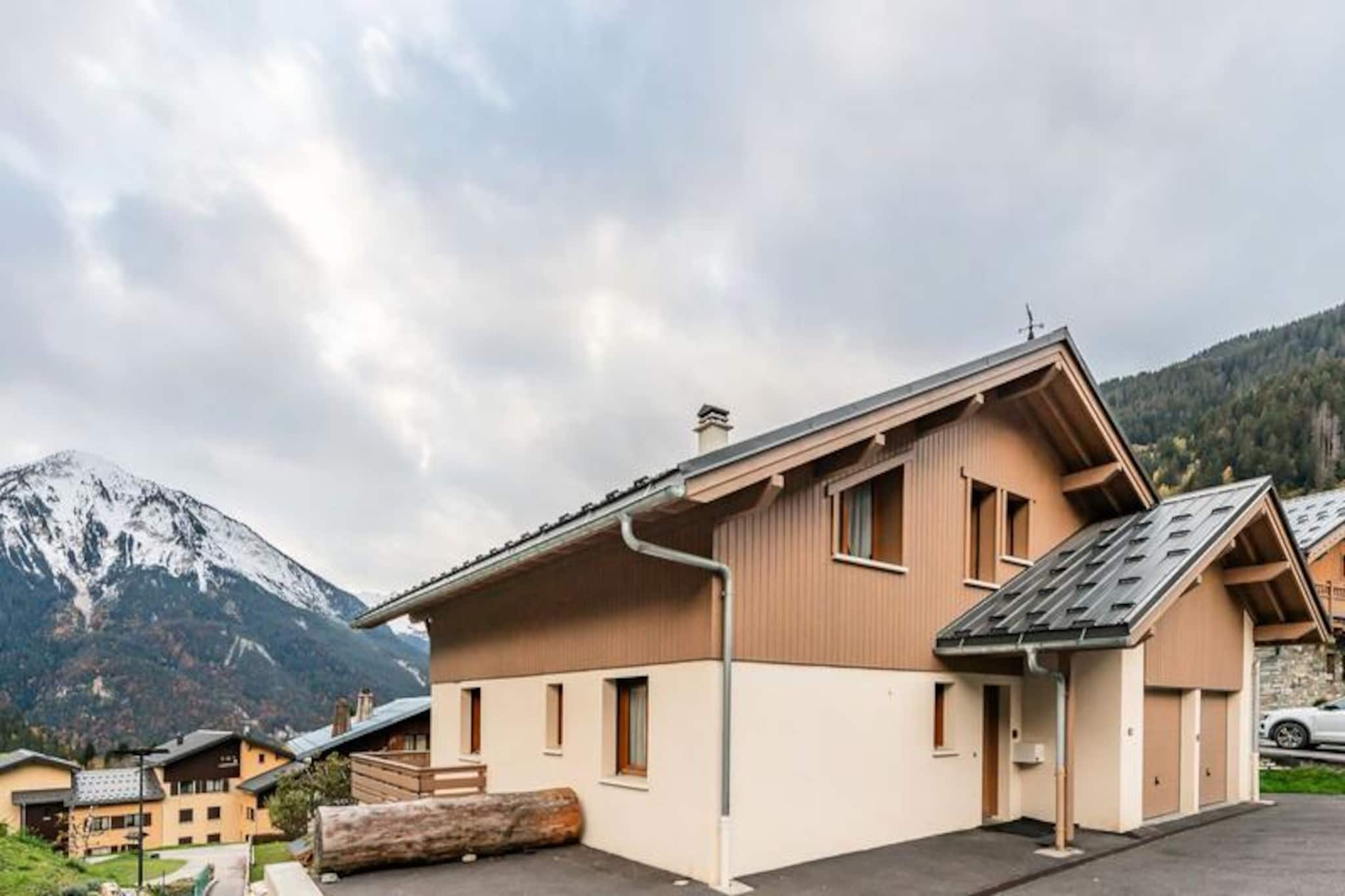 In the heart of the picturesque Trembley district of Champagny en Vanoise, Chalet LE SERAC offers a luxurious alpine retreat with breathtaking views of the Bozel Valley and Courchevel. This south-facing chalet is perfectly situated for those seeking both tranquility and convenience, with the village center just a five-minute walk away via a charming pedestrian path. Whether you're gazing at the arrival of the Mont de la Guerre slopes or enjoying the serene natural surroundings, this property promises an unforgettable mountain escape. 
 
 Spanning 160 m² across three levels, the chalet boasts spacious and thoughtfully designed interiors, ideal for families or groups of up to ten guests. The main floor features a cozy living room with a wood-burning stove, a dining area, and a fully equipped kitchen with modern appliances and a central island. Five beautifully appointed bedrooms, including a master suite with a private shower room and dressing area, ensure restful nights. Additional amenities such as a ski storage area with a boot dryer, a garage with two spaces, and three outdoor parking spots enhance the convenience of your stay. The chalet also offers a large bathroom with a bathtub, a baby dressing table, and two travel cots for families with young children. 
 
 Champagny en Vanoise is a gateway to adventure, with world-class skiing, hiking, and mountain biking trails at your doorstep. The nearby village center offers a delightful array of shops, restaurants, and services, while the natural beauty of the Vanoise National Park beckons outdoor enthusiasts. After a day of exploration, unwind on the chalet's terrace or by the fire, soaking in the panoramic alpine views. 
 
 With its premium location, modern comforts, and warm ambiance, Chalet LE SERAC is the perfect choice for creating cherished memories in the French Alps.