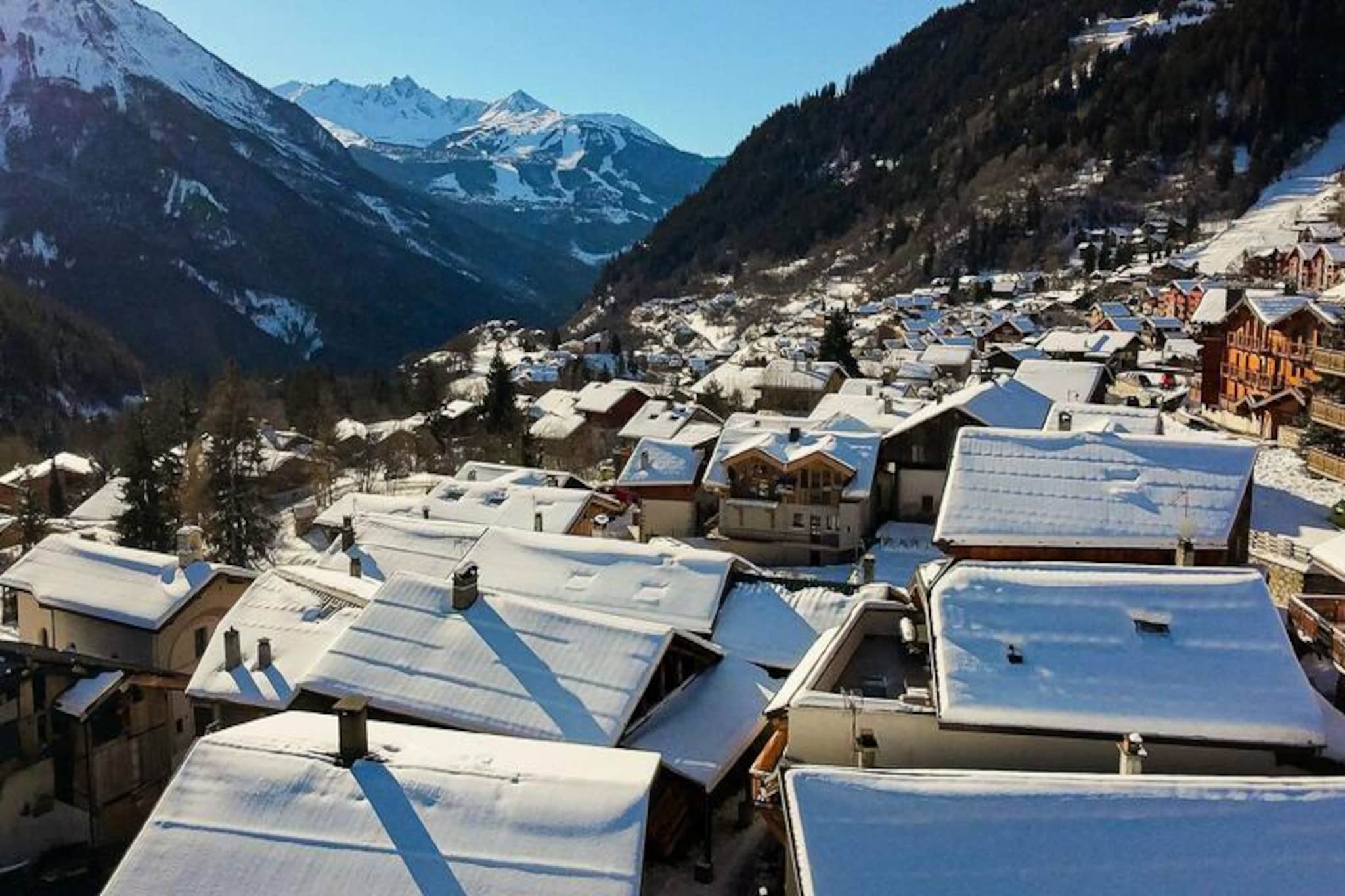 In the picturesque hamlet of Planay, nestled within the enchanting Champagny en Vanoise, L'ETOILE d'ARGENT invites you to experience the authentic charm of the Savoy Alps. This beautifully restored mountain house, dating back centuries, has been thoughtfully modernized to offer a perfect blend of tradition and contemporary comfort. With its south-facing terraces and breathtaking views of Courchevel and the Vanoise National Park, every moment here is bathed in alpine splendor. Whether you're seeking a winter wonderland or a summer retreat, this property welcomes you year-round to embrace the rhythm of the seasons. \n\nL'ETOILE d'ARGENT comprises two exquisite accommodations: PETIT PARADIS, a cozy 4-room duplex for up to six guests, and GRAND PARADIS, a spacious 8-room residence accommodating eight. Both feature elegant interiors crafted with noble materials like local stone, wooden floors, and marble accents. PETIT PARADIS spans three levels, offering a fully equipped kitchen, a sauna for ultimate relaxation, and balconies that frame the stunning alpine vistas. Every detail, from the antique-inspired linens to the modern amenities like high-speed Wi-Fi, ensures a stay of unparalleled comfort and charm. \n\nLocated just 700 meters from the village center and a mere 200 meters from a supermarket and shuttle stop, convenience is at your doorstep. Explore the nearby ski slopes in winter or embark on scenic hikes through the Vanoise National Park in summer. The historic charm of Planay, coupled with its proximity to world-class destinations like Courchevel, makes this property an ideal base for adventure and relaxation. \n\nL'ETOILE d'ARGENT is more than a place to stay; it’s a gateway to the heart of the Alps. Whether you’re savoring local Savoyard delicacies, unwinding in the sauna, or simply soaking in the panoramic views, this mountain retreat promises memories to treasure for a lifetime.