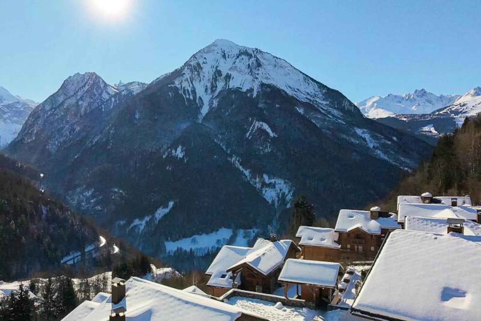 At the edge of the charming village of Champagny-en-Vanoise, surrounded by the pristine beauty of the Vanoise National Park, lies the cozy Les Alpages de Champagny residence. This peaceful hamlet of six large chalets offers a harmonious blend of alpine tradition and modern comfort, making it an ideal retreat for nature lovers and ski enthusiasts alike. With its south-facing orientation, guests are treated to breathtaking views of the Courchevel slopes and the majestic Vanoise massif, creating a serene backdrop for your holiday.
The residence boasts a range of premium amenities designed to enhance your stay. Relax in the heated indoor swimming pool, unwind in the spa with its hammam and sauna, or indulge in a soothing massage at the Infiniment Zen salon. Fitness enthusiasts will appreciate the on-site gym, while families can enjoy the convenience of a free shuttle service that runs every eight minutes in winter, connecting you to the resort center, cable car, and ESF ski school. Each apartment is thoughtfully equipped with a ski locker, covered parking space, and a sunny balcony to soak in the alpine views.
The apartment itself is a haven of comfort, featuring a west-facing terrace, a fully equipped kitchen, and a cozy living room with a pull-out sofa bed. The bedroom offers a plush double bed and ample storage, while the bathroom is fitted with a bathtub and heated towel rail for added luxury. Whether you’re here to ski the world-class slopes of Courchevel or explore the hiking trails of the Vanoise National Park, Les Alpages de Champagny provides the perfect base for your adventures.
Escape to this idyllic alpine retreat and create lasting memories amidst the stunning landscapes of the French Alps. With its exceptional amenities and prime location, this residence promises a holiday experience that is both relaxing and exhilarating.