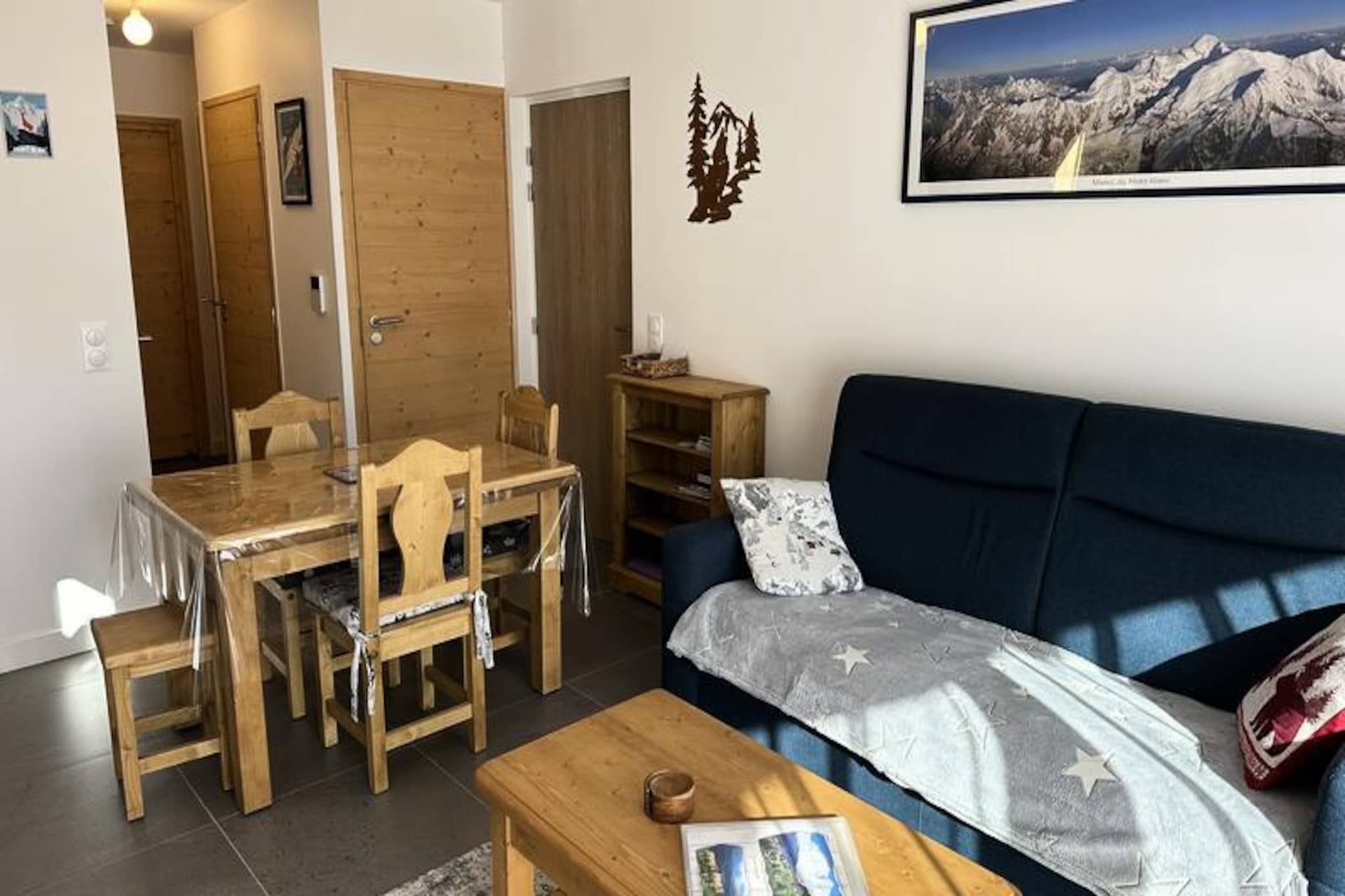 Surrounded by the breathtaking beauty of the French Alps, this charming apartment in the Chalet Flore residence offers a serene escape just 1 km from the picturesque village of Combloux. With its south/west-facing balcony, guests can soak in stunning mountain views while enjoying the crisp alpine air. Perfect for families or friends seeking a cozy retreat, this 48 m², 3-room apartment combines comfort and convenience for an unforgettable holiday experience. \n\nInside, the apartment is thoughtfully designed to accommodate up to four guests. The living room features a comfortable double sofa bed, a TV, and a dining area, creating a welcoming space to relax after a day of exploring. The open-plan kitchen is fully equipped with modern appliances, including a fridge/freezer, oven, ceramic hob, dishwasher, and washing machine, making meal preparation a breeze. The sleeping arrangements include a bedroom with a bunk bed and a master suite with a 160 cm double bed, ensuring restful nights for all. Additional amenities such as Wi-Fi, a ski locker, and private covered parking add to the convenience of your stay.\n\nLocated just 4 km from the ski slopes, this apartment is an ideal base for winter sports enthusiasts. In the warmer months, Combloux transforms into a haven for hikers and nature lovers, with trails that lead to panoramic vistas and lush alpine meadows. The village itself offers charming shops, traditional restaurants, and a warm, welcoming atmosphere that captures the essence of French mountain life.\n\nWhether you’re here to carve through powdery slopes or to unwind amidst stunning natural landscapes, this apartment provides the perfect blend of comfort, location, and alpine charm. Create lasting memories in the heart of the Alps, where every moment feels like a postcard-worthy adventure.