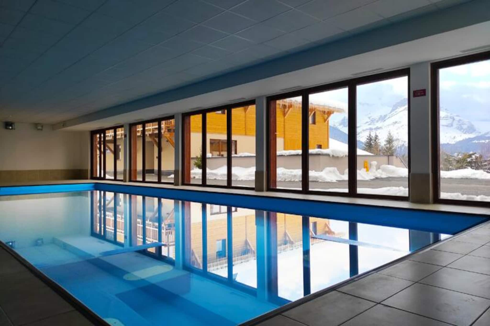 Amid the breathtaking landscapes of Haute-Savoie, Goélia Les Chalets des Pistes*** in Combloux invites you to experience a truly luxurious alpine retreat. Known as the 'pearl of Mont Blanc,' Combloux offers an enchanting blend of traditional charm and modern comforts, with panoramic views of Mont Blanc, the Aiguilles de Warens, and the Aravis ranges. Imagine waking up to the crisp mountain air on your private balcony or terrace, sipping coffee as the sun illuminates the majestic peaks surrounding you. This serene haven is perfect for unwinding and reconnecting with nature. \n\nThe residence boasts exceptional amenities designed for relaxation and indulgence. Dive into the heated indoor pool, let the stress melt away in the wellness area featuring a sauna and steam room, or pamper yourself with treatments in the dedicated spa rooms. Each chalet is thoughtfully equipped with a convertible sofa bed, a kitchenette, and a bathroom, ensuring a comfortable and convenient stay. Families with young children will appreciate the availability of baby kits, while pet owners can bring their furry companions along for the adventure. \n\nCombloux’s charm extends beyond the residence. Explore over 30 km of marked hiking trails, discover hidden treasures in the village, or venture to nearby Megève and Chamonix, just a short drive away. The region offers activities for every taste, from alpine adventures to cultural experiences. Whether you're seeking tranquility or excitement, Combloux delivers an unforgettable escape. Let the beauty of Haute-Savoie and the warmth of Goélia Les Chalets des Pistes*** create memories that will last a lifetime.