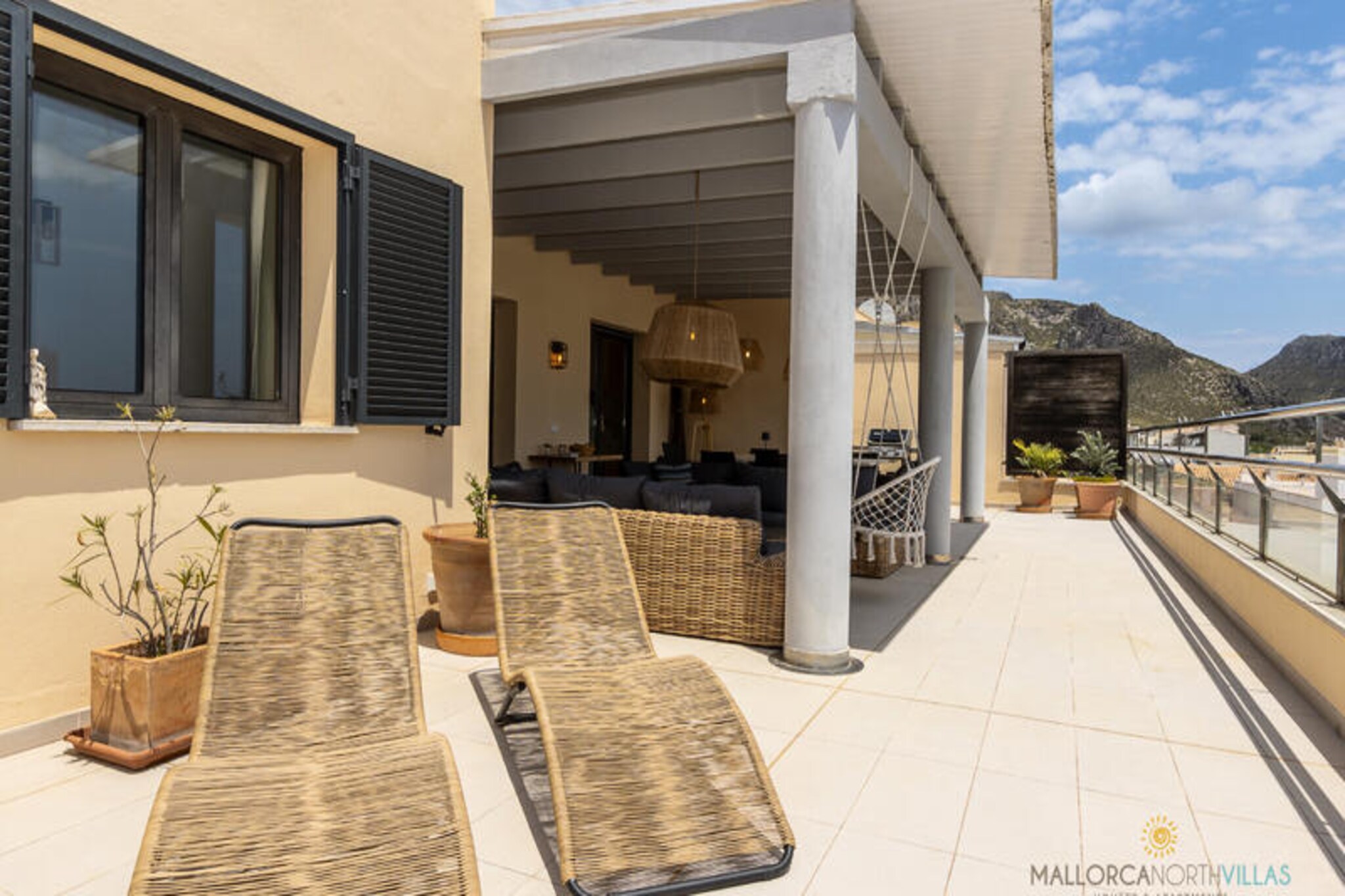 Imagine waking up to the gentle sound of the Mediterranean breeze and breathtaking views of the Tramuntana mountains. This stunning penthouse in the heart of Puerto de Pollensa offers the perfect blend of modern luxury and Mallorcan charm. Just a short stroll from the vibrant town square, golden beaches, and delightful restaurants, this property is an oasis for those seeking a memorable getaway.
The penthouse boasts four beautifully designed bedrooms. Two double bedrooms feature plush double beds and en-suite bathrooms with bathtubs, providing a serene retreat. A third double bedroom, with two single beds and an en-suite shower, is perfect for friends or children, while a cozy single bedroom accommodates an extra guest or child. An additional guest toilet adds convenience for all. The fully equipped kitchen, with its central island and modern appliances, invites you to create culinary delights, while the sunlit living room, framed by large windows, offers a tranquil space to unwind.
Step outside to discover the property’s two private terraces. The front terrace, with its panoramic mountain views, is ideal for morning coffee or evening drinks, while the interior terrace, featuring partial sea views and elegant lounge furniture, is perfect for sunset gatherings or a barbecue with loved ones. Guests also have access to a shared pool and terrace, perfect for cooling off and mingling with fellow travelers. An underground parking space ensures added convenience.
Whether you’re exploring the charming streets of Puerto de Pollensa, relaxing by the pool, or enjoying the nearby beaches, this penthouse is your gateway to an unforgettable Mallorcan escape. Book your stay now and let the magic of the Mediterranean captivate you.