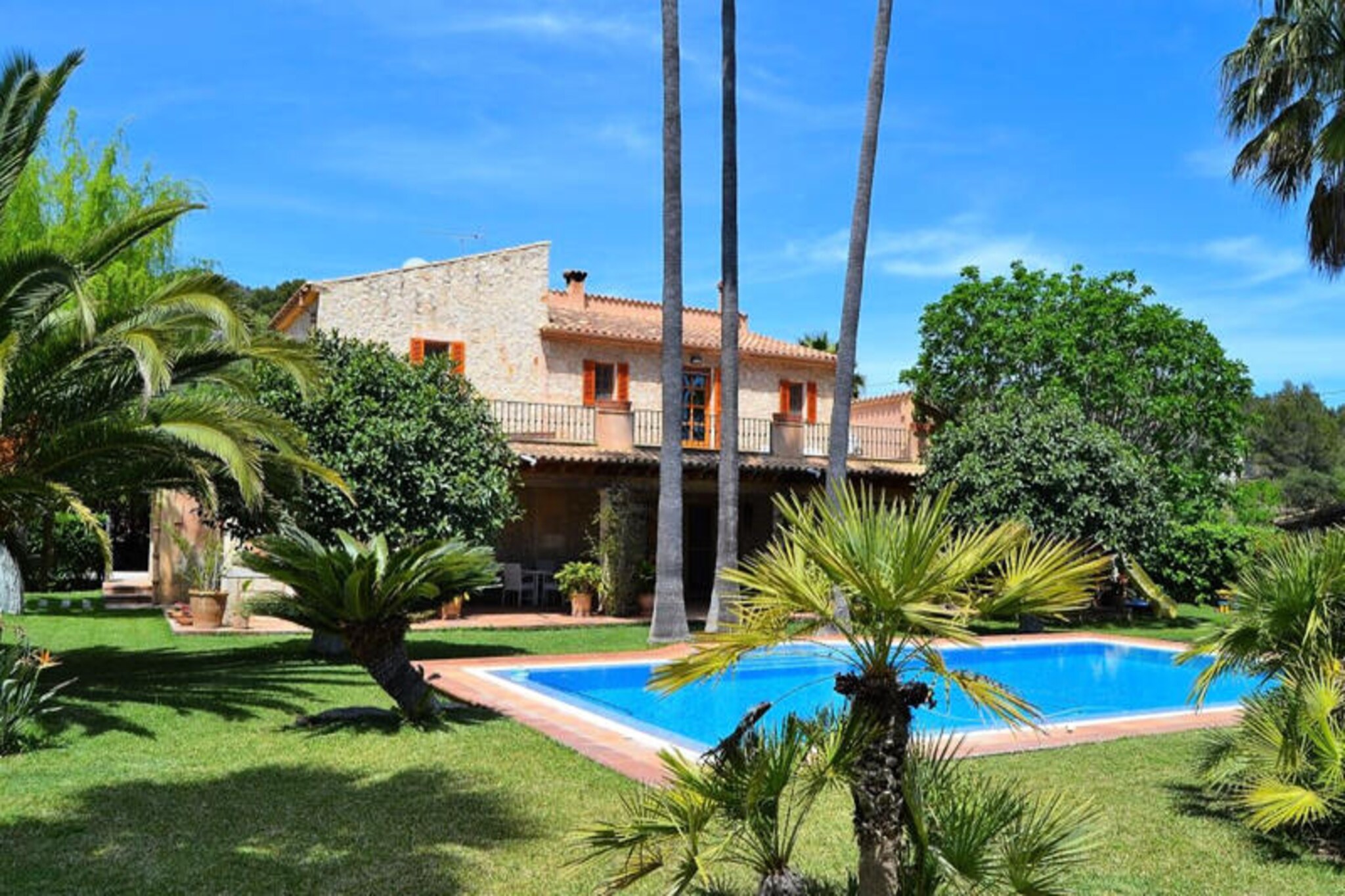 In the heart of Mallorca’s serene countryside, this exquisite family villa offers a perfect blend of luxury and tranquility. Surrounded by the island’s renowned vineyards and just a short drive from the charming village of Binissalem, this property invites you to immerse yourself in the authentic Mallorcan lifestyle. Whether you’re seeking a peaceful retreat or an adventure-filled getaway, this villa provides the ideal setting for unforgettable moments. \n\nSpanning an impressive 360 m² over two floors, the villa is designed with both comfort and elegance in mind. The ground floor features a spacious living-dining area, a fully equipped kitchen with terrace access, a cozy bedroom, and a guest bathroom. Upstairs, you’ll find four beautifully appointed bedrooms, including one with an en-suite bathroom, another with a private sauna, and a third with an open dressing room. Modern furnishings and meticulous attention to detail create a welcoming atmosphere throughout. The villa also includes satellite TV and high-speed WiFi, ensuring all the conveniences of home.\n\nStep outside to discover a lush 2,000 m² garden, complete with a large swimming pool (10m x 5m), sun loungers, and a shaded terrace perfect for al fresco dining. Younger guests will adore the indoor children’s park, while adults can savor evenings by the outdoor barbecue. The peaceful surroundings and family-friendly amenities make this villa a true haven for relaxation.\n\nLocated near Binissalem, the villa is perfectly positioned for exploring Mallorca’s wine culture and natural beauty. Visit local wineries, enjoy traditional Mallorcan cuisine, or take a scenic drive to the island’s stunning beaches and mountains. Whether you’re here to unwind or explore, this villa promises a memorable stay for families and friends alike.