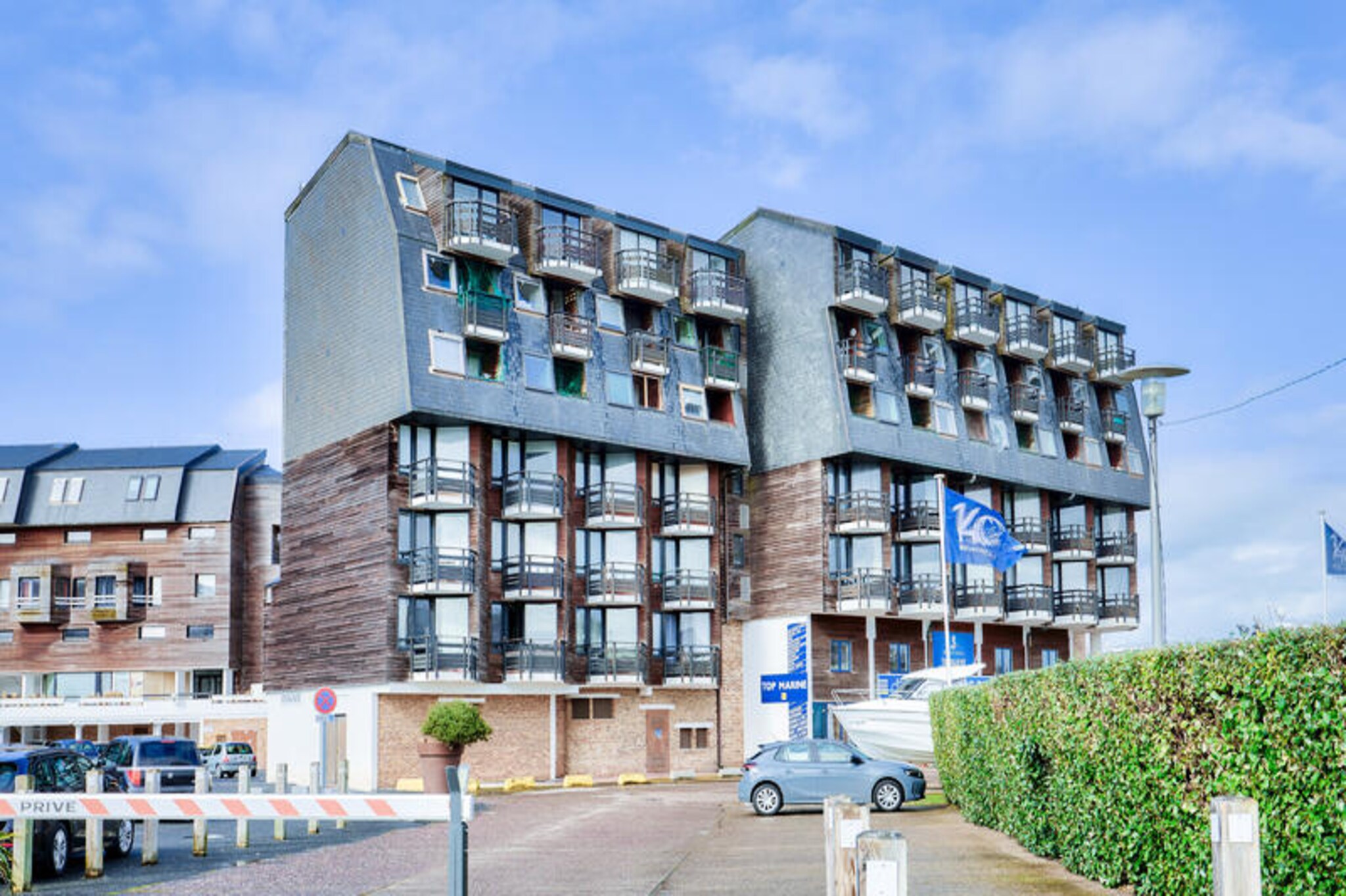 In the charming Port Deauville district, this ground-floor apartment offers a delightful retreat just 500 meters from the sandy shores of Deauville Beach. Perfectly situated for seaside escapes, the residence combines convenience with comfort, making it an ideal choice for families or friends seeking a relaxing getaway. Imagine waking up to the gentle sea breeze, stepping out onto your private balcony, and enjoying the vibrant coastal atmosphere that surrounds you. With its proximity to the town center, you’re just moments away from Deauville’s renowned elegance and charm. \n\nDesigned to accommodate up to five guests, the apartment boasts a cozy living room with a sofa bed, a fully equipped kitchen, a comfortable bedroom with a double bed, and a sleeping alcove for added privacy. Modern amenities such as a dishwasher, microwave, coffee maker, and Wi-Fi ensure a stress-free stay, while the option for additional services like linen and cleaning adds flexibility to your vacation plans. Public parking is available, and the residence features an elevator and bicycle storage for added convenience. \n\nExplore the vibrant surroundings with ease. The beach is a short stroll away, while nearby attractions include the Deauville International Centre, the famous La Touques Racecourse, and the thermal center, all within walking distance. For those seeking adventure, the Caen Memorial and Arromanches Landing Beach offer fascinating historical excursions just a drive away. Golf enthusiasts will appreciate the nearby course, while tennis and equestrian centers provide further leisure options. \n\nWhether you’re drawn to the allure of Deauville’s sophisticated charm, the excitement of its cultural and sporting events, or simply the tranquility of the seaside, this apartment offers the perfect base for creating unforgettable memories along the Normandy coast.
