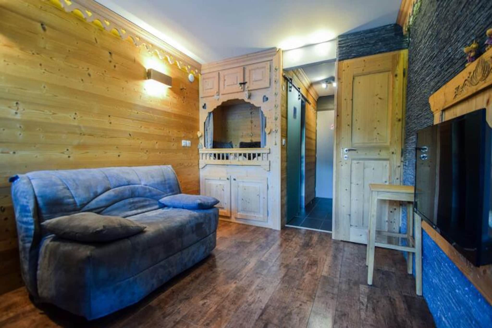 High above the bustling slopes of Plagne Centre, this charming studio apartment offers a cozy alpine retreat with breathtaking views of the ski runs and resort below. Situated on the 7th floor of the Aconcagua Residence, guests can enjoy a south-facing balcony that captures the essence of mountain living, whether basking in the morning sun or watching skiers carve their way down the pistes. Perfectly suited for couples, this intimate space combines convenience and comfort for an unforgettable getaway in the heart of the Paradiski domain. \n\nThe 18m² studio is thoughtfully designed to maximize every inch of space, featuring a well-equipped kitchen with ceramic hobs, a refrigerator with freezer, and a microwave for preparing meals after a day on the slopes. The living area includes a dining table and a comfortable double sofa bed, ideal for relaxing evenings with a favorite show on the TV. The hardwood flooring adds a touch of warmth, while the modern bathroom with a shower ensures a refreshing start to your day. Additional amenities include a ski locker for easy access to your gear, making your alpine adventures seamless and stress-free. \n\nLocated just 150 meters from the slopes and 300 meters from the shopping mall, the Aconcagua Residence places you at the center of everything. Whether you’re picking up ski passes, exploring local shops, or indulging in après-ski dining, everything is within easy reach. The vibrant atmosphere of Plagne Centre offers endless activities, from thrilling descents to cozy evenings in the village. \n\nChoose this delightful studio for its unbeatable location, panoramic views, and thoughtful amenities. Whether you’re here for skiing, snowboarding, or simply soaking in the alpine charm, this property promises a memorable stay in one of France’s most iconic mountain destinations.