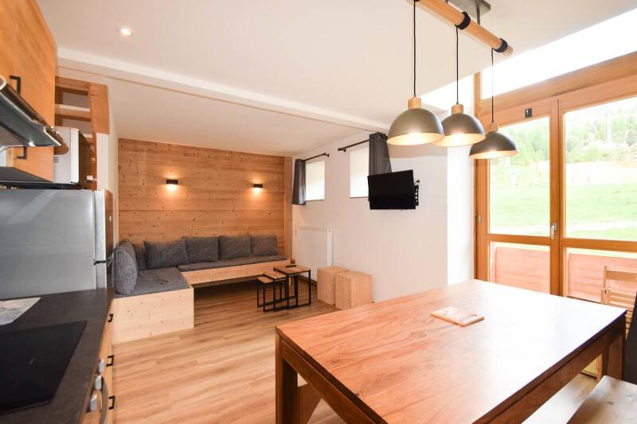 High above the charming alpine village of Plagne Centre, this spacious duplex apartment offers a front-row seat to the slopes, making it a dream destination for ski enthusiasts. Imagine waking up to the sight of snow-dusted peaks from your south-facing balcony, stepping out into the crisp mountain air, and skiing directly from your doorstep into the heart of the Paradiski domain. The residence's convenient location, connected to shops and amenities via a covered gallery, ensures everything you need is within easy reach. Whether you're here for the thrill of the slopes or the serene beauty of the Alps, this apartment is your gateway to unforgettable adventures.
Designed to accommodate up to nine guests, the apartment spans two levels and combines comfort with functionality. The first floor features a fully equipped kitchen with modern appliances, a cozy living room with a dining area, and a corner sofa that converts into two single beds. Upstairs, you'll find three bedrooms, including a master bedroom with a double bed, a cabin room with bunk beds and a single bed, and a twin room. Two bathrooms—one with a shower and the other with a bathtub—ensure convenience for larger groups. Additional amenities like a washing machine, multiple TVs, and a ski locker add to the ease of your stay.
Step outside, and you're immediately on the slopes, ready to explore the vast Paradiski area with its 425 kilometers of interconnected runs. After a day of skiing, return to the comfort of your apartment or explore the vibrant après-ski scene in Plagne Centre. In summer, the region transforms into a haven for hikers and mountain bikers, with trails that wind through breathtaking alpine landscapes. The nearby Vanoise National Park offers opportunities for wildlife spotting and tranquil nature walks.
Whether you're visiting for the snow or the sunshine, this duplex apartment in Residence Le France is the perfect base for creating lasting memories in the French Alps.