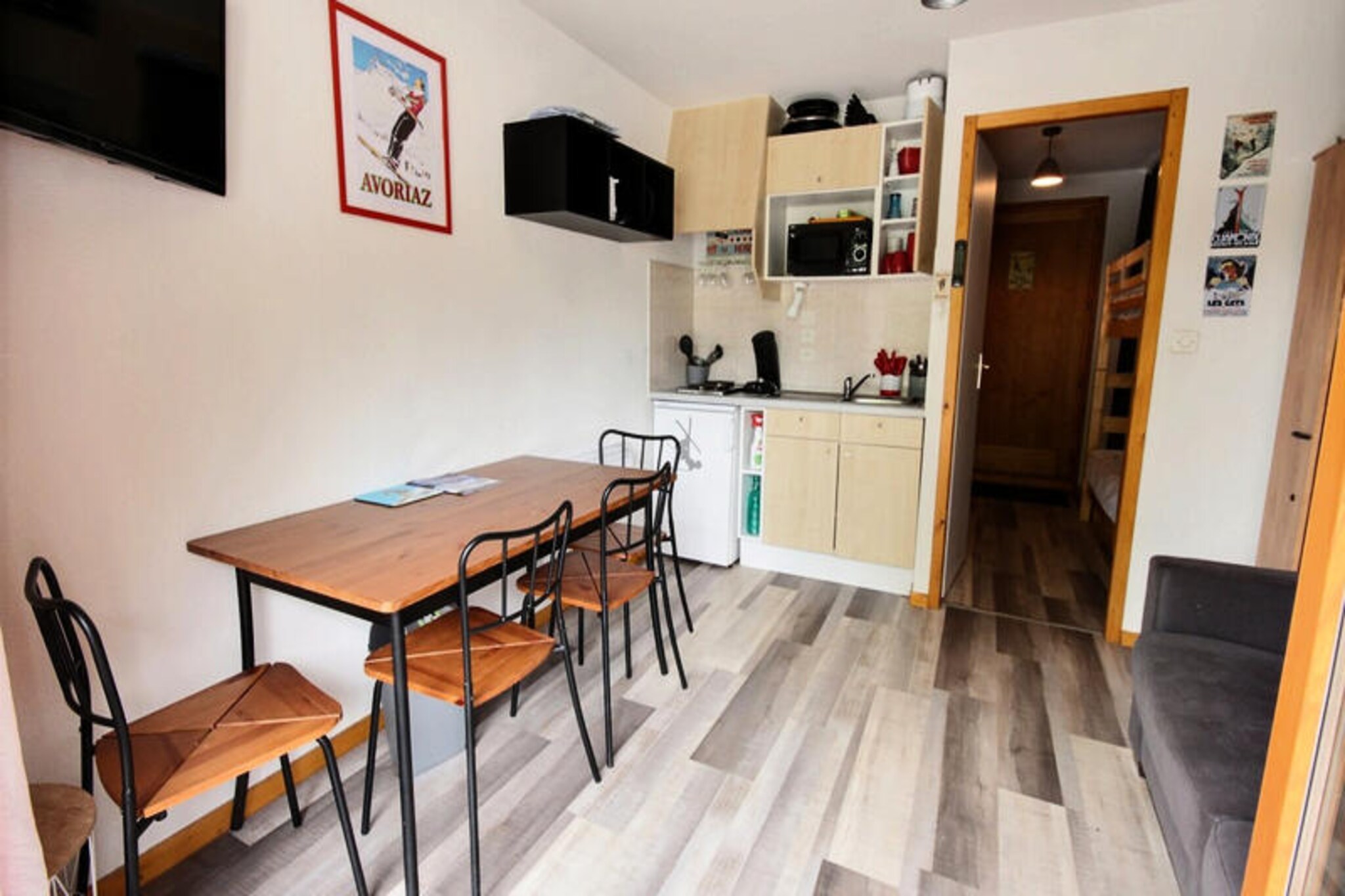 In the picturesque village of Saint Jean d'Aulps, this charming studio offers an ideal retreat for ski enthusiasts and nature lovers alike. Just 100 meters from the ski lifts of the La Grande Terche resort, you’ll find yourself perfectly positioned to explore the stunning Espace Roc d’Enfer ski area. Whether you’re carving through forested slopes or enjoying breathtaking views of the Roc d’Enfer, this destination promises unforgettable alpine adventures. For even more variety, the renowned slopes of Morzine-les Gets and Avoriaz, with access to Switzerland, are just a short drive away. \n\nThis cozy studio is thoughtfully designed to accommodate up to four guests. The layout includes a sleeping alcove with bunk beds, a main living area featuring a sofa bed, a dining space, and a compact yet functional kitchen equipped with essentials like a mini-oven, refrigerator, and coffee maker. A private north-facing balcony offers serene views of the valley and parking area, perfect for unwinding after a day on the slopes. Additional amenities include a raclette grill for cozy alpine dinners and shared parking for your convenience. Please note that bed linens and towels are not provided, and pets are not allowed.\n\nBeyond the comfort of your studio, the region offers a wealth of attractions. From the tranquil shores of Lake Montriond, just 10.8 km away, to the vibrant ski town of Morzine, there’s something for everyone. The nearby Portes du Soleil ski area, one of the largest in the world, is easily accessible, offering endless opportunities for skiing, snowboarding, and even cross-border adventures into Switzerland. In summer, the area transforms into a haven for hikers and cyclists, with lush trails and panoramic vistas.\n\nWhether you’re seeking thrilling winter sports or a peaceful summer escape, this studio in Saint Jean d'Aulps is your gateway to the beauty and excitement of the French Alps. Book your stay today and create memories that will last a lifetime.