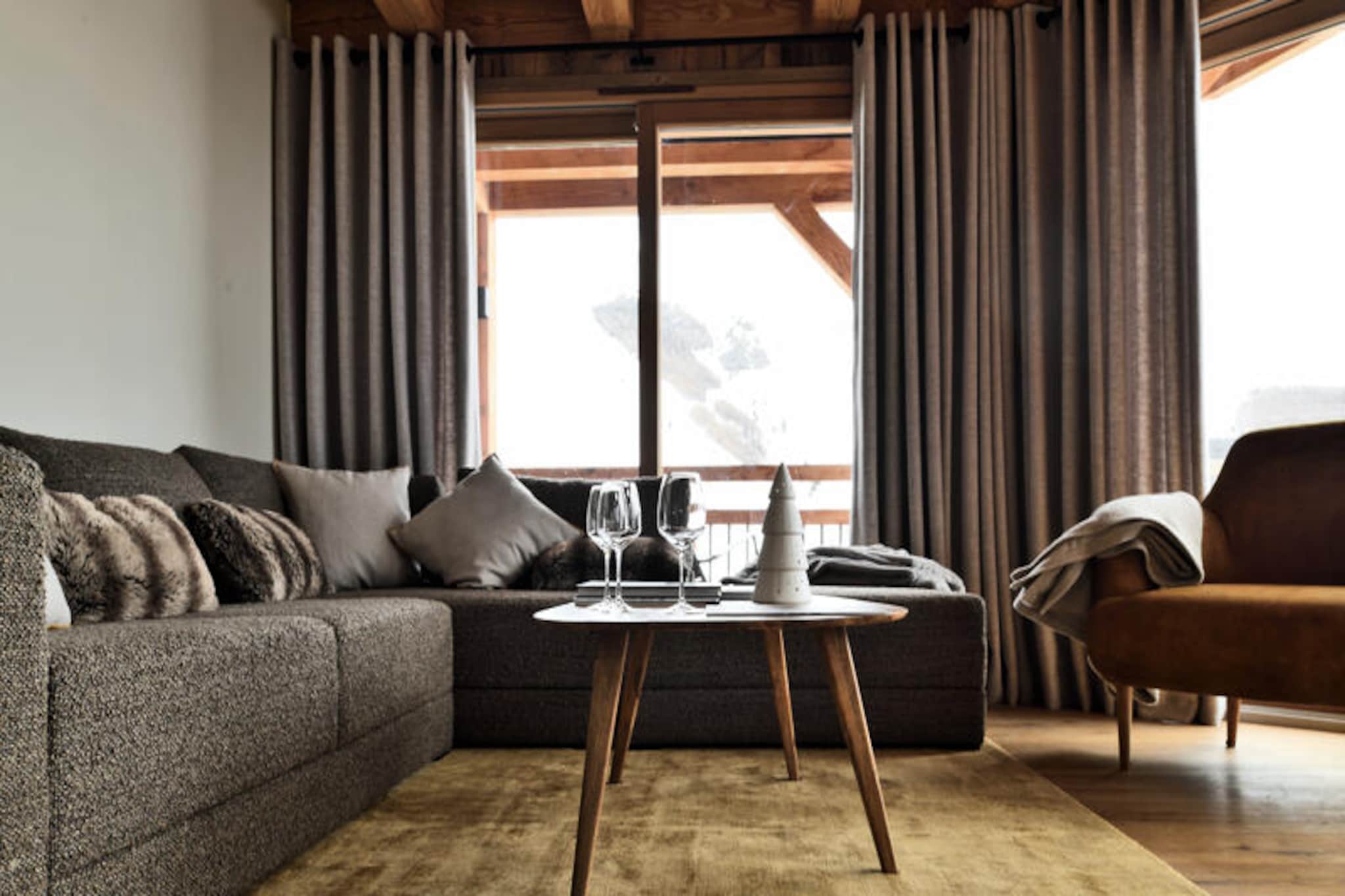 High in the heart of the French Alps, this luxurious 131 m² apartment offers an unparalleled alpine retreat for up to 10 guests. With its southwest-facing orientation, the property boasts breathtaking panoramic views of the surrounding peaks, creating an atmosphere of serenity and exclusivity. Whether you're seeking adventure on the slopes or a peaceful mountain escape, this chalet-style apartment is the perfect base for your holiday.
The apartment is thoughtfully designed across two levels, blending modern comfort with alpine charm. On the entrance level, you'll find a fully equipped kitchen with premium appliances, a cozy bedroom with a double bed and private shower room opening onto the terrace, and a relaxation area featuring a sauna, lap pool, and shower. Upstairs, a dormitory with bunk beds and additional sleeping arrangements ensures ample space for families or groups, while two double bedrooms with private shower rooms provide added privacy. A private ski room with boot dryers, a garage, and an additional parking space add convenience to your stay.
Located in the heart of the mountains, this property offers easy access to world-class ski slopes and hiking trails. After a day of outdoor adventures, unwind in the sauna or enjoy a meal prepared in the well-appointed kitchen. Nearby, charming alpine villages and local restaurants invite you to explore the region's rich culture and cuisine.
With its exceptional amenities, stunning views, and prime location, this apartment promises an unforgettable alpine experience. From the moment you arrive, every detail is designed to ensure a seamless and luxurious stay, making it the perfect choice for your next mountain getaway.