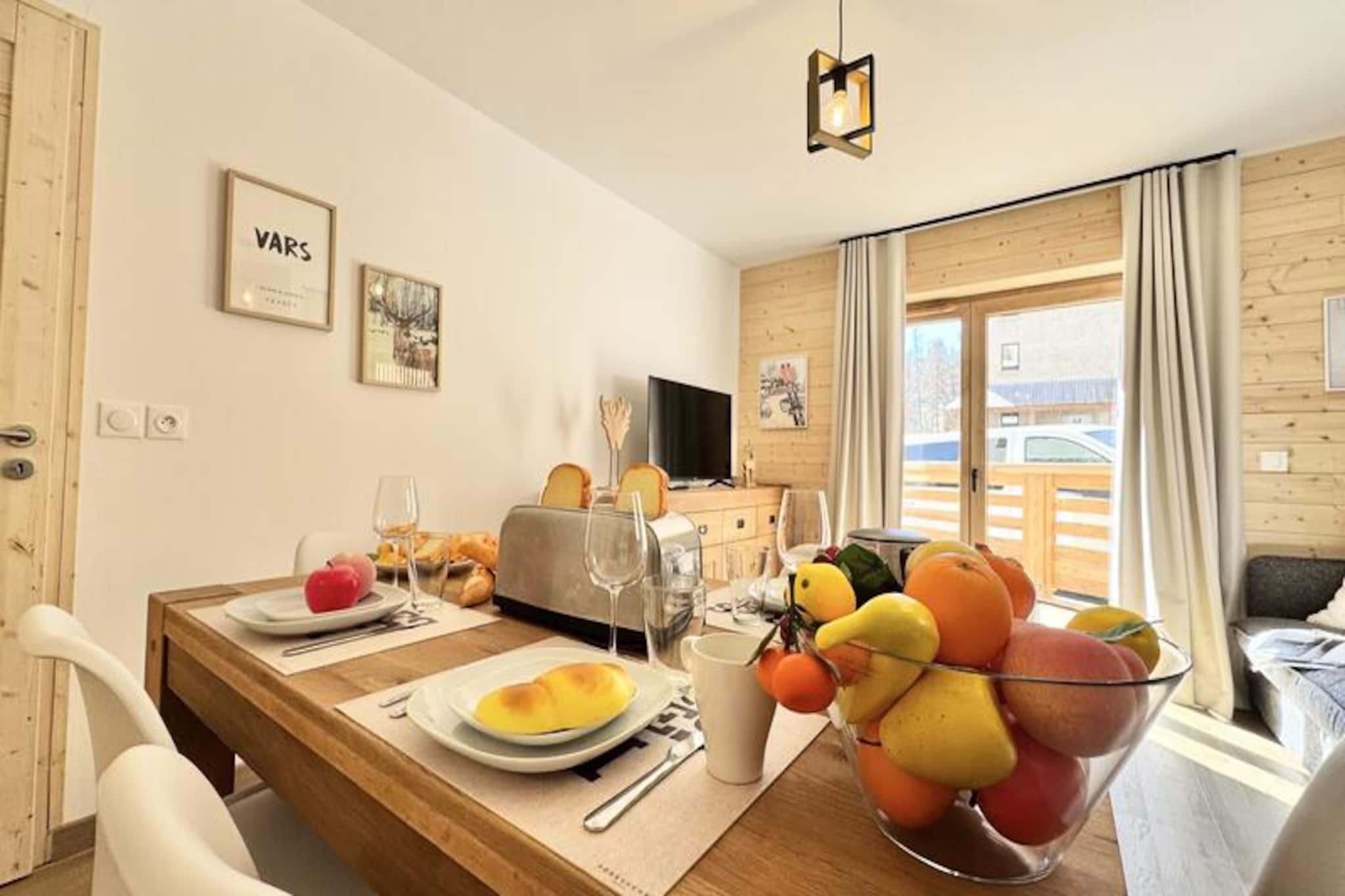In the vibrant heart of Vars Les Claux, this newly built residence offers an exceptional alpine retreat just steps from the shops and a mere 150 meters from the ski slopes. Imagine waking up to the crisp mountain air and soaking in the natural light from your southeast-facing terrace, as the snow-covered peaks beckon you to explore. Whether you're here for winter sports or summer hikes, this modern apartment is your gateway to the beauty of the French Alps. \n\nInside, the apartment boasts a spacious and contemporary living room equipped with a TV, seamlessly connected to an open-plan kitchen. The kitchen is a chef's dream, featuring high-end appliances such as a Nespresso coffee machine, juicer, and dishwasher, ensuring every meal is a pleasure to prepare. The sleeping arrangements are designed for ultimate comfort, with a cozy bedroom offering two 120 x 200 cm beds and a second bedroom featuring a luxurious 160 x 200 cm double bed. A sleek bathroom and separate toilet complete the layout, while the private covered parking space adds convenience to your stay. \n\nThe residence’s prime location places you within easy reach of the ski slopes, making it perfect for avid skiers and outdoor enthusiasts. In summer, the surrounding trails and breathtaking landscapes offer endless opportunities for adventure. Nearby shops and restaurants ensure you have everything you need at your fingertips, while the charm of Vars adds a touch of magic to your vacation. \n\nWith linens provided, beds made upon arrival, and end-of-stay cleaning included, this apartment guarantees a hassle-free and memorable stay. Whether you're seeking thrilling days on the slopes or tranquil evenings in the mountains, this property is your ideal home away from home in Vars Les Claux.