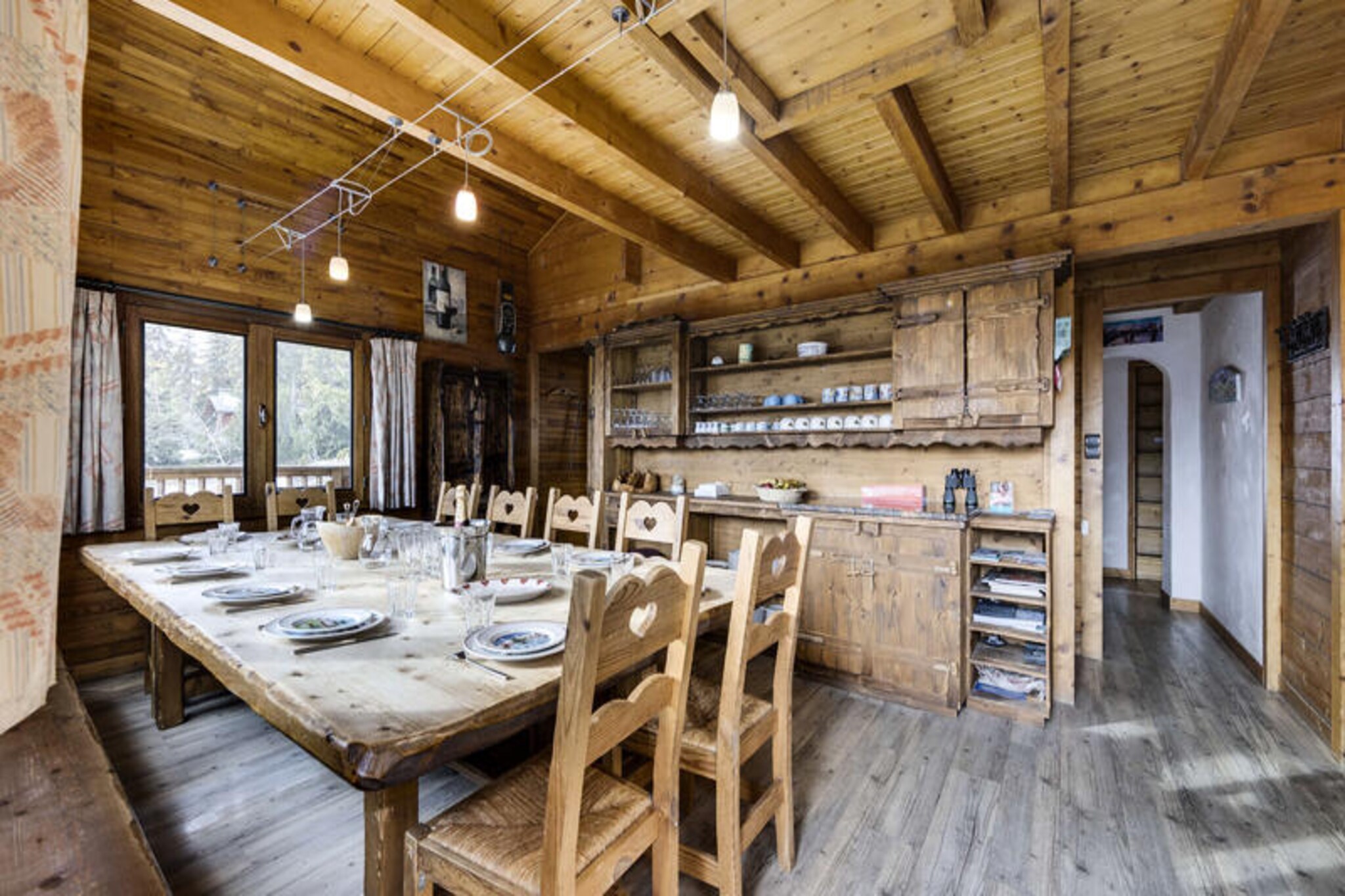 High in the serene alpine village of La Rosière, Chalet Chocard offers an exceptional retreat where panoramic mountain views and luxurious amenities come together to create an unforgettable holiday. Bathed in sunlight, this 195m² chalet in the Gollet district invites you to experience the charm of the French Alps with its perfect blend of modern comfort and traditional alpine character. Whether you're planning a winter ski escape or a summer mountain adventure, this chalet is your gateway to relaxation and exploration. 
 
 Step inside to discover a thoughtfully designed space that accommodates up to 15 guests. The spacious living room, complete with a dining area and a fully equipped kitchen, is the heart of the home, perfect for gathering after a day of activities. The south-facing balcony offers breathtaking views, while the private hammam and outdoor Jacuzzi on the terrace provide the ultimate relaxation. The chalet boasts a variety of sleeping arrangements, including double bedrooms with en-suite bathrooms, cozy bunk beds for children, and a family suite that ensures everyone has their own space. Modern conveniences like Wi-Fi, a ski room, and on-site reception services make your stay effortless and enjoyable. 
 
 La Rosière is known for its exceptional ski slopes in winter and scenic hiking trails in summer. The chalet's prime location places you close to the slopes, ensuring easy access to the renowned Espace San Bernardo ski area. In the warmer months, explore the surrounding valleys, indulge in local Savoyard cuisine, or simply unwind on the sunlit terrace. With its combination of comfort, convenience, and stunning surroundings, Chalet Chocard is the perfect choice for families and groups seeking an alpine escape like no other. 
 
 Let the beauty of the French Alps and the warmth of Chalet Chocard create memories you'll cherish forever.