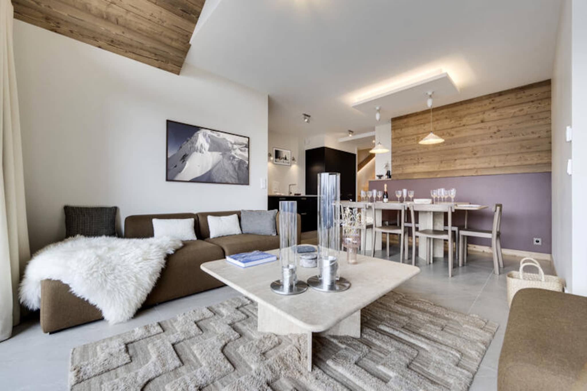 High above the picturesque valley of La Rosière, this charming alpine retreat in Le Vieux Village offers a harmonious blend of rustic charm and modern comfort. With sweeping views of the surrounding peaks and a tranquil atmosphere, this property is perfect for families and groups seeking an unforgettable mountain escape. Whether you're here for the snow-covered slopes in winter or the lush hiking trails in summer, the chalet's prime location ensures every adventure is just moments away. \n\nSpanning 96m², the apartment comfortably accommodates 6 adults and 2 children. The spacious living room invites you to unwind after a day outdoors, while the open-plan kitchen and dining area are perfect for shared meals and cozy evenings. The layout includes three well-appointed bedrooms, two with shared shower rooms and one with a private bathroom. A south-facing terrace offers a sunny spot to relax and soak in the alpine scenery. For ultimate relaxation, the chalet features a sauna with an additional shower, ensuring guests can rejuvenate in style. Modern amenities such as Wi-Fi, a ski room, and covered parking add convenience to your stay. \n\nLa Rosière is renowned for its family-friendly ski slopes and vibrant village atmosphere. In winter, explore the vast Espace San Bernardo ski area, while summer brings opportunities for hiking, mountain biking, and breathtaking views of Mont Blanc. The chalet’s proximity to local shops, restaurants, and cultural sites makes it an ideal base for exploring the region. \n\nWith its welcoming ambiance, thoughtful amenities, and prime location, this alpine haven is more than just a holiday rental—it's a gateway to unforgettable memories in the heart of the French Alps.