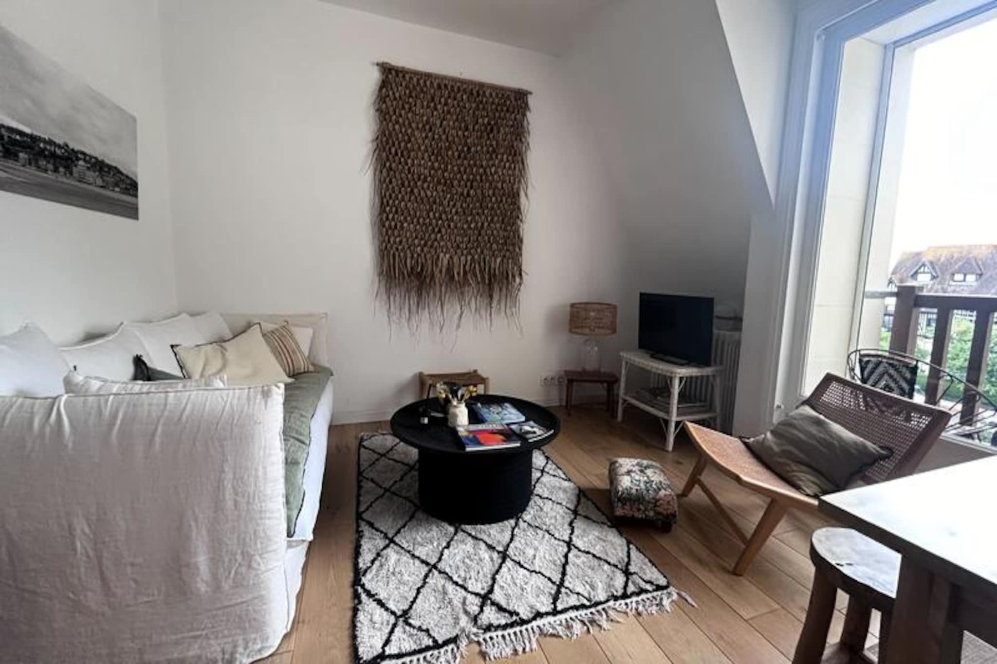 With the gentle rhythm of the waves and the charm of Normandy’s coastline, this elegant duplex apartment in the heart of Deauville’s port offers a serene retreat for up to five guests. Imagine waking up to the fresh sea breeze, stepping onto your private balcony, and soaking in the vibrant atmosphere of this iconic seaside town. Whether you’re here for a romantic getaway or a family vacation, the location places you at the center of Deauville’s allure. 
                      Spanning 60 m² on the fourth floor, the apartment boasts a bright and inviting living space complete with a daybed, an open-plan kitchen, and a dining area that comfortably seats six. Two cozy bedrooms, each with double beds, promise restful nights, while the modern bathroom with a walk-in shower ensures convenience. Thoughtful amenities such as a washing machine and personalized services like beds made upon arrival and final cleaning add to the ease of your stay. 
                      Just steps from the sea and surrounded by Deauville’s renowned shops, restaurants, and cultural attractions, you’ll find everything you need within walking distance. Stroll along the famous boardwalk, explore the local markets, or indulge in fresh seafood at nearby eateries. For those seeking adventure, the region offers horseback riding, golf courses, and scenic trails to discover the beauty of Normandy. 
                      Whether you’re drawn to the golden sands, the lively marina, or the timeless elegance of Deauville, this apartment is your gateway to unforgettable coastal memories. Let the charm of Normandy envelop you in a vacation filled with relaxation and discovery.