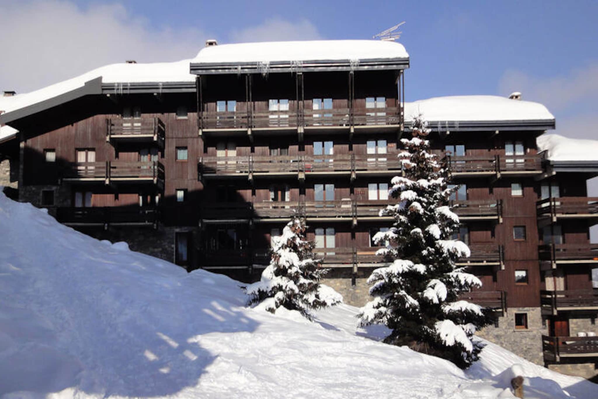 High above the shimmering slopes of Méribel-Mottaret, this charming alpine retreat offers a perfect blend of comfort and convenience for your mountain getaway. Imagine waking up to breathtaking views from your south-facing balcony, sipping coffee as the sun rises over the snow-capped peaks. With direct ski access right from the residence, adventure awaits just steps from your door, making it an ideal choice for winter sports enthusiasts and nature lovers alike. Whether you're here to carve through fresh powder or explore scenic trails, every moment feels like a celebration of the great outdoors. \n\nInside, the residence is thoughtfully designed to accommodate up to six guests across its 45m² space. The cozy living room features a dining area, a lounge with a double sofa bed, and a wood-burning stove that adds a touch of rustic charm (wood not provided). The kitchenette is fully equipped with modern appliances, including a fridge, dishwasher, induction hobs, mini-oven, microwave, and more, making it easy to prepare meals after a day on the slopes. Two inviting bedrooms offer flexible sleeping arrangements—a double bed in one and a combination of bunk beds and a single bed in the other—ensuring restful nights for all. Additional amenities include a flat-screen TV, free internet access (connection subject to operator availability), and a washing machine for added convenience. \n\nSituated just 500 meters from the Mottaret shopping center, accessible via stairs or cable car, you'll find everything you need within easy reach. From ski rentals and après-ski spots to charming boutiques and local eateries, the village buzzes with life and alpine charm. In summer, the area transforms into a haven for hikers and cyclists, with lush trails and panoramic views waiting to be explored. \n\nWhether you're seeking thrilling ski days, tranquil evenings by the stove, or unforgettable moments surrounded by the beauty of the French Alps, this residence invites you to create lasting memories in one of the region's most picturesque settings.
