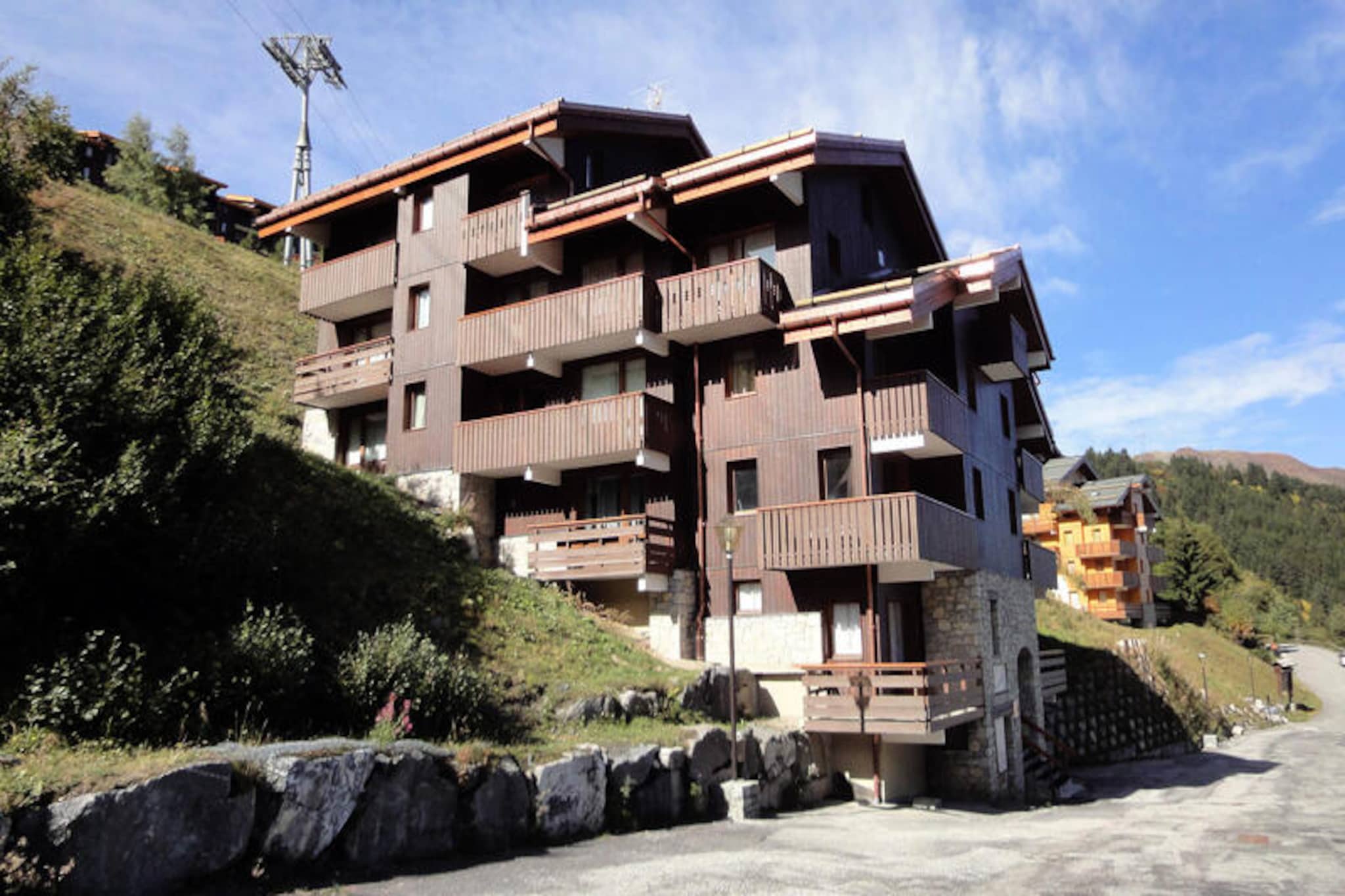 High in the French Alps, where the crisp mountain air invigorates the senses, the Asphodèles residence offers a charming alpine retreat perfect for families and small groups. Positioned just 200 meters from the slopes, this cozy apartment provides a seamless connection to the vibrant ski culture of Méribel-Mottaret. Whether you're a seasoned skier or a first-time visitor, the surrounding snow-covered peaks create an idyllic backdrop for your mountain adventures.
This 38m², 3-room apartment comfortably accommodates up to 6 guests. The thoughtfully designed layout includes a cozy living room with a set of trundle beds, a sleeping area with a double sofa bed separated by a sliding door, and an upper level featuring a small bedroom with a double bed and another bedroom with a single bed and trundle bed. The open-plan kitchenette is equipped with modern appliances, including a Nespresso coffee maker, microwave with grill, and dishwasher, making it easy to prepare meals after a day on the slopes. A northeast-facing balcony offers a serene spot to relax and soak in the alpine views. Additional amenities include a flat-screen TV, shoe dryer, and individual water heater for your comfort. Pets are welcome, making it a perfect getaway for the whole family.
Conveniently located between the Le Hameau and town center shopping areas, the residence ensures easy access to local amenities. The Chalets cable car, just 150 meters away, operates from early morning to late evening, providing free access to the slopes and surrounding areas. Nearby, the Perdrix green run leads directly to the main ski lift departure point, making your ski days effortless.
Whether you're visiting for the thrill of skiing or the tranquility of the mountains, the Asphodèles residence is your gateway to an unforgettable alpine escape. With its prime location, comfortable amenities, and breathtaking surroundings, it promises a holiday filled with cherished memories.
