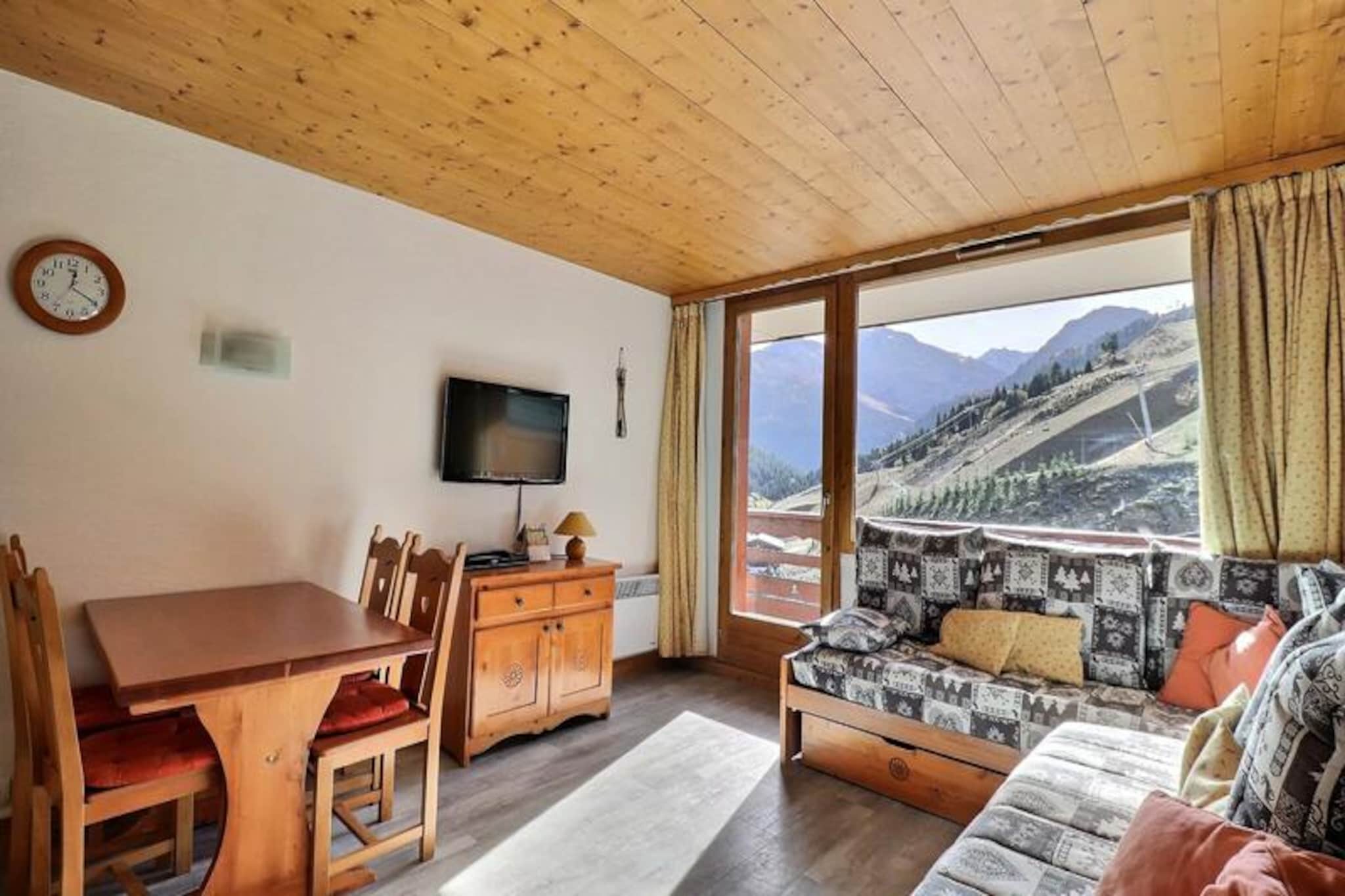 In the heart of the enchanting Méribel-Mottaret, this charming apartment in the Plein Soleil residence offers a perfect alpine escape. Imagine waking up to the crisp mountain air, stepping onto your south-facing balcony, and gazing at the majestic peaks that surround you. With its unbeatable ski-in, ski-out location, you can glide directly from the ski lockers to the pristine slopes, immersing yourself in the world-class Three Valleys ski area. Whether you're here for winter sports or summer hikes, this residence places you at the center of it all. \n\nThe apartment, rated 3 stars and carrying the prestigious Méribel Label, is thoughtfully designed for up to five guests. Its cozy living room features a single sofa bed and a set of trundle beds, while the separate bedroom offers two comfortable single beds. The kitchen is fully equipped with modern appliances, including a combination microwave oven, dishwasher, and coffee makers, making it easy to prepare hearty meals after a day of adventure. A flat-screen TV, free Wi-Fi in the residence lounge, and a washing machine add to the convenience, ensuring a comfortable and stress-free stay. \n\nBeyond the apartment, the Plein Soleil residence boasts a prime location near shops and amenities in the heart of Mottaret. The Chalets cable car, just steps away, provides free and easy access to the Hameau and Laitelet areas from early morning until late at night. Whether you're exploring the vibrant village or embarking on a thrilling day on the slopes, everything you need is within reach. \n\nThis delightful retreat combines charm, comfort, and an unbeatable location, making it the ideal choice for families, couples, or friends seeking an unforgettable alpine getaway. Let the magic of Méribel-Mottaret captivate you as you create memories to last a lifetime.