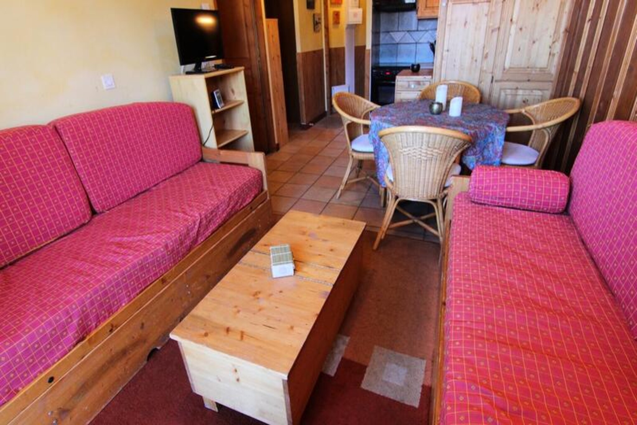 High above the bustling resort of Val Thorens, Chalet No. 6 at Les Balcons offers a serene alpine retreat with breathtaking panoramic views of the surrounding peaks. Located just a five-minute walk from the resort center, this charming chalet combines tranquility with convenience. Its south/southwest-facing balcony invites you to soak in the sun while marveling at the majestic mountain vistas. Whether you're here for the snow-covered slopes or the vibrant après-ski scene, this location ensures you're at the heart of it all. A free shuttle service is also available for added ease. \n\nStep inside this cozy 35m² two-room apartment, thoughtfully designed to accommodate up to five guests. The living room features a tiled floor, a pull-out sofa bed that transforms into two single beds, and an additional single bed, creating a welcoming space to unwind after a day of adventure. The separate bedroom offers two comfortable single beds, ensuring restful nights for all. The well-equipped kitchen includes an oven, induction hob, refrigerator, dishwasher, microwave, and extractor hood, making it easy to prepare delicious meals. The bathroom features a bathtub and sink, while a separate toilet adds extra convenience. Free Wi-Fi is included, keeping you connected throughout your stay. \n\nThe chalet's prime location places you just moments from the slopes, perfect for ski enthusiasts eager to hit the trails. Nearby, you'll find ski rental shops, grocery stores, and restaurants, ensuring all your needs are met. Paid parking is available in the residence for those arriving by car. Whether you're seeking thrilling winter sports or a peaceful summer escape, Chalet No. 6 is your gateway to the best of Val Thorens. Create unforgettable memories in this idyllic alpine haven.