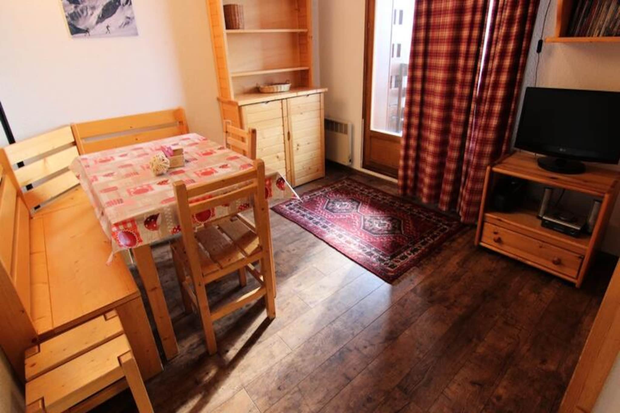 In the serene Arolles district of Val Thorens, this charming apartment offers a tranquil retreat with direct access to the slopes. Perfectly situated at the entrance of the resort, it boasts exceptional southwest exposure, inviting you to bask in the alpine sun while enjoying breathtaking mountain views from your private balcony. Whether you're seeking a peaceful getaway or thrilling days on the pistes, this property caters to every mood and moment. \n\nDesigned for up to four guests, the apartment features a cozy and functional layout. The bedroom is equipped with a comfortable double bed, while the cabin provides snug bunk beds, making it ideal for families or small groups. The kitchenette is fully equipped with a microwave, electric stovetop, refrigerator, dishwasher, and extractor hood, ensuring you have everything needed to prepare delicious meals after a day of adventure. The bathroom includes a bathtub and sink, and the toilet is conveniently separate. Modern amenities like heating and elevator access add to the comfort of your stay.\n\nJust 200 meters away, you'll find the Caron shopping center, offering local shops and the Val Thorens sports center with a swimming pool and wellness area. Ski enthusiasts will appreciate the proximity to the SKISET/GOITSCHEL SPORT GS4 rental shop, also within 200 meters. The residence’s location on the resort map (72/C3) ensures easy navigation and access to all the highlights of Val Thorens.\n\nWhether you're here for the world-class skiing, relaxing spa experiences, or simply to soak in the beauty of the French Alps, this apartment provides the perfect base for creating unforgettable memories. Let the charm of La Reine Blanche residence and the allure of Val Thorens make your alpine escape truly special.