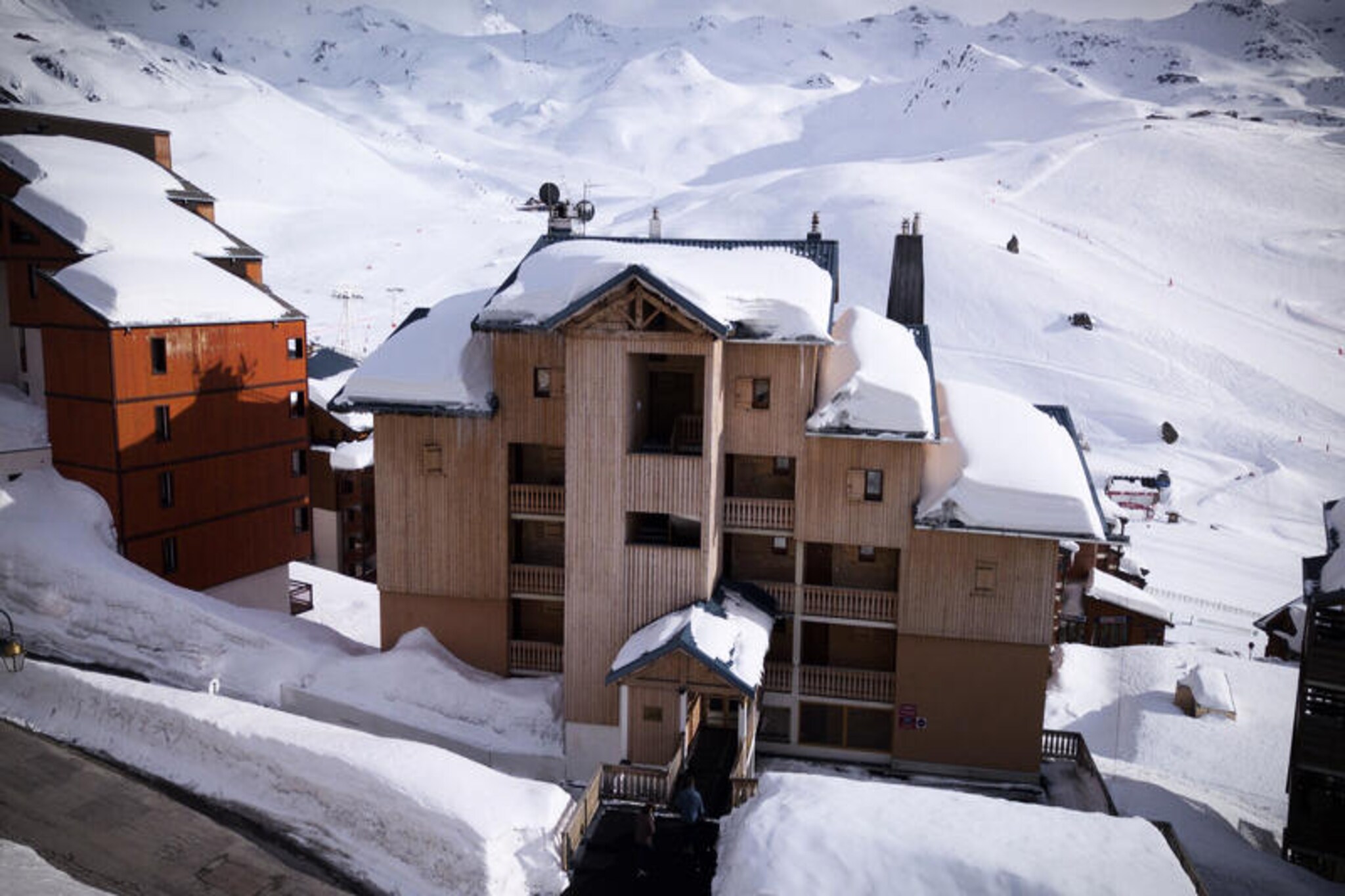 In the serene Arolles district at the entrance to the resort, the Beausoleil chalet offers a tranquil escape perfect for families seeking a peaceful alpine retreat. Just 150 meters from the Caron shopping and sports center, and a short stroll to the Soleil district with its ski schools, ticket office, and kindergarten, this location combines convenience with calm. Whether you're here for winter sports or summer adventures, the chalet places you close to everything while maintaining a quiet ambiance ideal for relaxation. With the slopes just 20 meters away, your alpine adventures begin almost at your doorstep. \n\nThis charming 3-room apartment spans 50 m² and comfortably accommodates up to four guests. The south-facing balcony invites you to soak in the sunshine and enjoy views of the surrounding mountain scenery. Inside, the cozy living room features a fireplace, television, and a comfortable sofa, creating a warm and inviting space to unwind after a day of activities. The kitchenette is well-equipped with a multifunction microwave, ceramic hob, refrigerator, dishwasher, and extractor fan, making it easy to prepare meals for your group. The sleeping arrangements include a double bed in the master bedroom and two bunk beds in the second room, ideal for families or small groups. A separate bathroom with a bathtub and sink, along with a separate toilet, ensures comfort and convenience throughout your stay.\n\nBeyond the chalet, the resort offers a wealth of amenities and activities. From ski equipment rental at the nearby Skiset store to exploring the vibrant Soleil district, everything you need is within walking distance. In winter, enjoy the thrill of skiing with slopes just steps away, while summer opens up opportunities for hiking, biking, and discovering the natural beauty of the French Alps. The Arolles district’s calm atmosphere paired with its proximity to key facilities makes Beausoleil chalet a perfect choice for your alpine getaway. Whether you’re seeking adventure or tranquility, this cozy retreat promises unforgettable memories in the heart of the mountains.