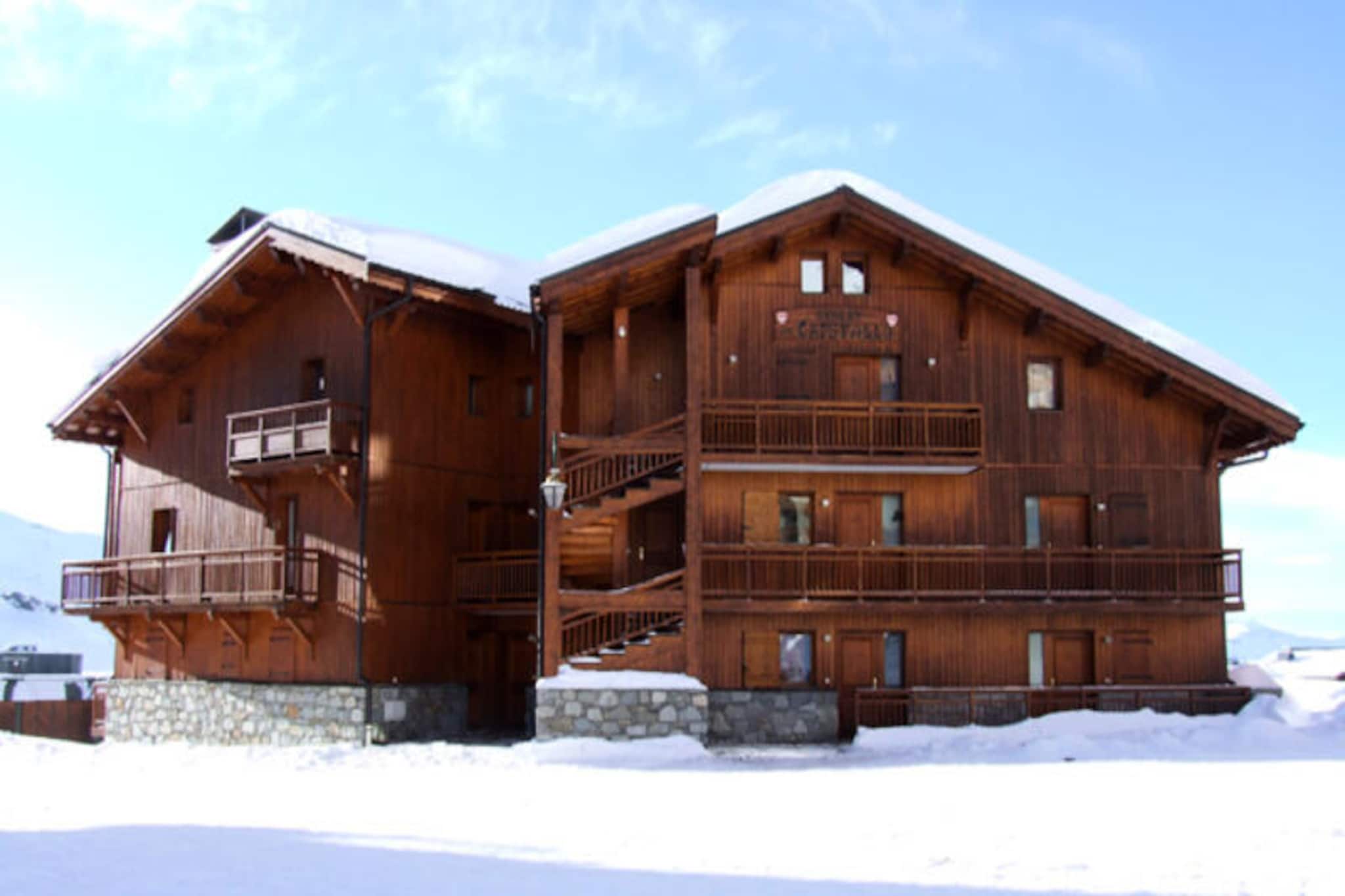 In the serene Slalom district of Val Thorens, the Cristallo chalet offers a tranquil retreat amidst the world-renowned Three Valleys ski area. Perfect for families seeking both comfort and convenience, this spacious 3-room apartment is located just 50 meters from the ski lift ticket office, ensuring effortless access to the slopes. With the Péclet shopping center and a variety of restaurants only 200 meters away, everything you need for a memorable alpine getaway is within easy reach. From the southwest-facing balcony, soak in the breathtaking views of the snow-covered peaks and enjoy the crisp mountain air. \n\nDesigned to accommodate up to six guests, the apartment features a well-equipped kitchen with modern appliances including an oven, ceramic hob, dishwasher, washing machine, and microwave—ideal for preparing hearty meals after a day of skiing. The living room invites relaxation with its television and pull-out sofa bed, while the main bedroom and sleeping cabin each offer comfortable double beds. A bathroom with a bathtub and sink, along with a separate toilet, ensures convenience for all guests. \n\nFamilies will appreciate the proximity to the ESF Mini Club, making it an excellent choice for those traveling with children. Nearby, the Snowberry and GS1 SKISET shops provide easy access to ski equipment rentals, while the resort’s paid Wi-Fi ensures connectivity throughout your stay. For added convenience, a garage is available for rent within the residence. \n\nWhether you’re here to carve through pristine slopes or simply relax in the peaceful ambiance of the Slalom district, the Cristallo chalet promises an unforgettable alpine experience. Let the magic of Val Thorens captivate you as you create cherished memories in this cozy mountain retreat.