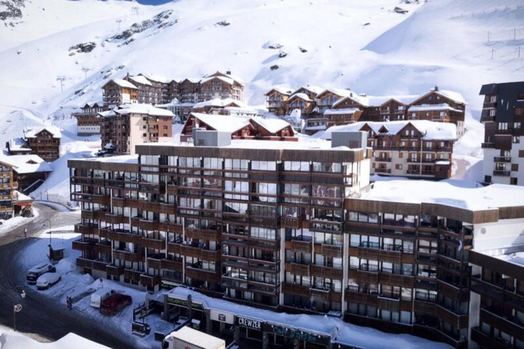 High above the vibrant heart of Val Thorens, this cozy studio in the Névés residence offers a perfect alpine retreat for those seeking adventure and lively après-ski moments. Positioned in the bustling Péclet district, the residence is surrounded by a dynamic mix of pubs, bars, and restaurants, ensuring that your evenings are as memorable as your days on the slopes. With the Péclet shopping mall just across the street, convenience is at your doorstep, whether you're picking up ski gear or indulging in a quick bite. \n\nThis 25m² studio, located on the first floor with elevator access, comfortably accommodates up to four guests. The space is thoughtfully designed with a kitchenette featuring an oven, microwave, refrigerator, ceramic hob, and even a mini dishwasher, making it easy to prepare meals after a day of alpine exploration. The living room includes a pull-out sofa that converts into two single beds, a television, and a DVD player for cozy evenings in. A separate bunk bed area, screened by a curtain, adds privacy and charm. The bathroom features a bathtub and sink, while a separate toilet adds convenience. A southwest-facing veranda invites you to soak in the mountain views and crisp alpine air. \n\nJust 70 meters from the slopes, this studio places you at the heart of the action. Whether you're a seasoned skier or a first-timer, the proximity to the lifts ensures effortless access to the world-class runs of Val Thorens. After a day on the snow, immerse yourself in the vibrant nightlife or unwind in the comfort of your studio. With its unbeatable location and cozy amenities, this property is an ideal choice for an unforgettable alpine getaway.