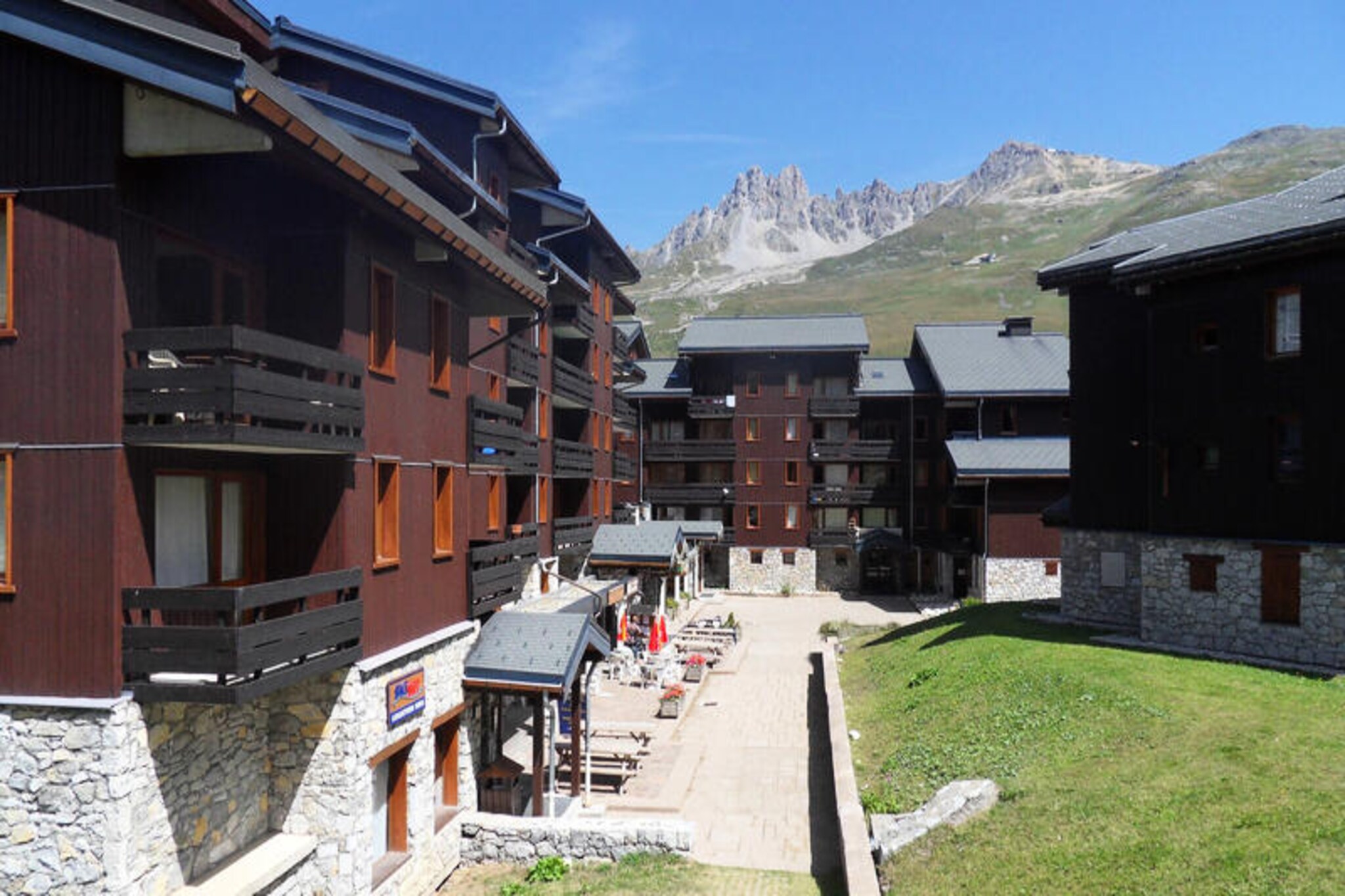 In the vibrant Hameau shopping center of Le Laitelet, this charming studio apartment offers a cozy alpine retreat for up to four guests. With direct access to the slopes, your ski adventure begins just steps from the residence’s ski lockers. Imagine gliding onto the green run that leads to the main ski lift departure point, or strapping on your skis right outside the locker when snow conditions allow. The Chalets cable car, operating from early morning to late evening, provides seamless access to the surrounding areas, ensuring convenience throughout your stay. \n\nThis south-facing studio is thoughtfully designed for comfort and practicality. The living room features a double sofa bed, while a sliding wall separates the bedroom with two single beds, offering flexibility for families or small groups. The kitchenette is fully equipped with modern appliances, including a microwave oven, refrigerator, dishwasher, and essential coffee-making tools, perfect for preparing meals after an active day. A flat-screen TV, heating, and a private balcony complete the amenities, providing a relaxing space to unwind and enjoy the stunning alpine views. \n\nBeyond the residence, the Hameau shopping center offers a variety of shops and dining options, making it easy to explore local flavors and pick up essentials. Whether you’re here to ski, hike, or simply soak in the serene mountain atmosphere, this property places you at the heart of it all. With its pet-friendly policy and non-smoking environment, it’s an ideal choice for a stress-free getaway. \n\nChoose this delightful studio for your next alpine escape and create unforgettable memories in the breathtaking French Alps.