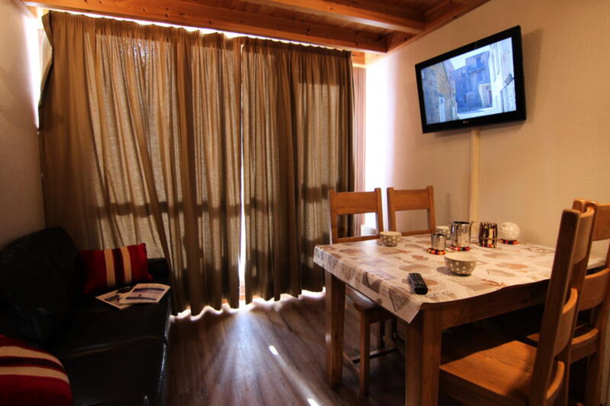Bathed in the golden hues of the Soleil district, this charming Silveralp residence offers a cozy alpine retreat with direct access to the slopes just across the road. Whether you're waking up to the crisp mountain air or unwinding on the southwest-facing balcony, every moment here is infused with the serene beauty of the French Alps. The nearby shops and restaurants add convenience, while the resort center is easily accessible via elevator and footbridge, ensuring you're never far from the vibrant heart of the village. \n\nInside, the two-room mezzanine apartment combines functionality with comfort across its 36 m² of space. The kitchenette is equipped with a dishwasher, oven, electric stovetop, and refrigerator, making it easy to prepare hearty meals after a day of adventure. The living room invites relaxation with its cozy sofa, television, and dining area, while the bathroom features a bathtub and sink for soothing moments of self-care. Upstairs, the mezzanine offers flexible sleeping arrangements with a pull-out sofa bed in the cabin and two single beds in the bedroom, perfect for families or small groups. \n\nStep outside and you'll find yourself surrounded by the allure of the Soleil district. From the slopes just across the road to the nearby shops and restaurants, everything you need is at your fingertips. In winter, the area transforms into a snowy paradise, while summer brings opportunities for hiking, biking, and exploring the breathtaking alpine landscapes. The resort map ensures easy navigation, making it simple to discover hidden gems and local treasures. \n\nWhether you're seeking thrilling ski adventures or tranquil mountain escapes, this Silveralp residence is your gateway to unforgettable alpine memories. With its blend of comfort, convenience, and stunning surroundings, it promises a holiday experience that lingers long after you've left.