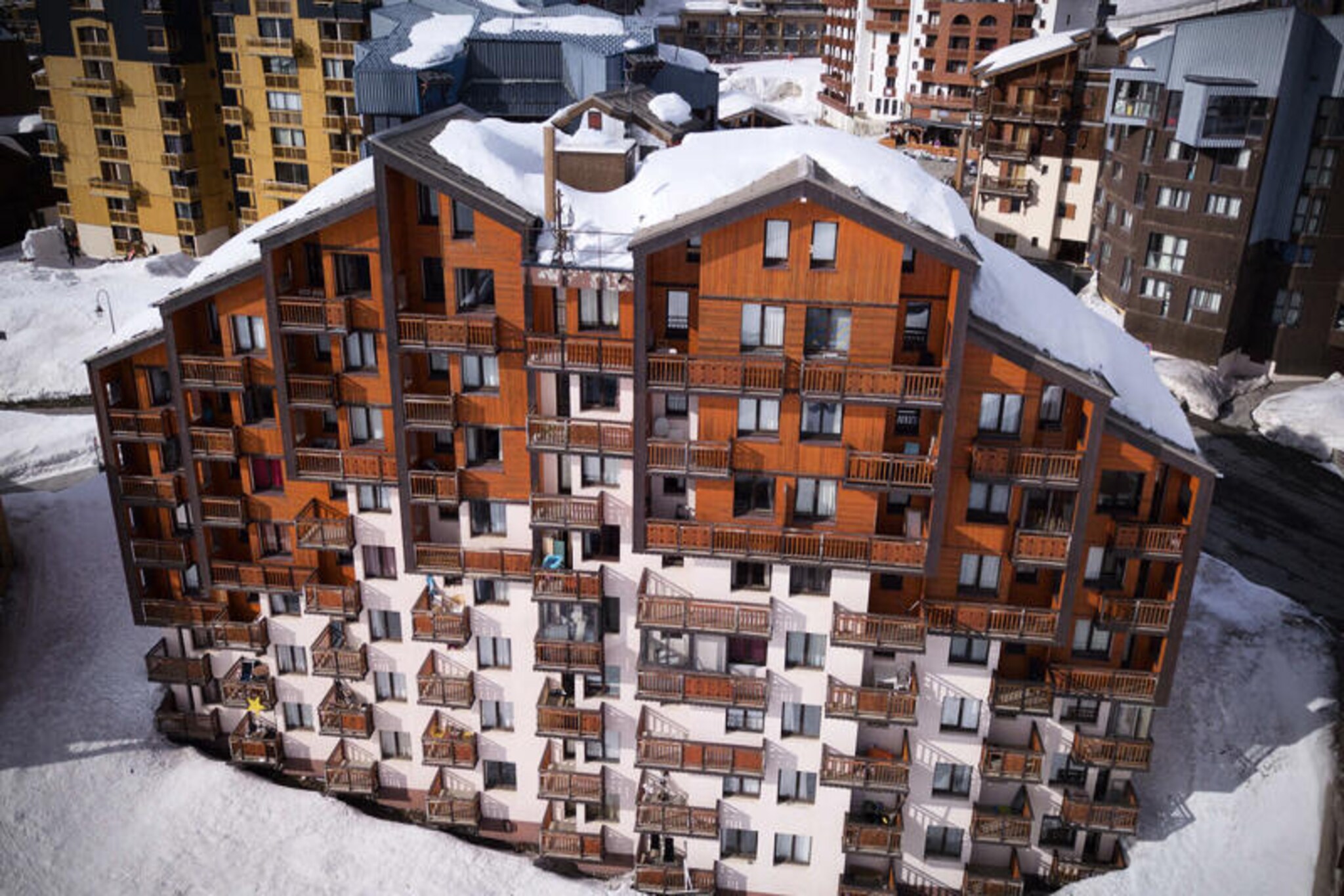 At the gateway to the vibrant Arolles district, this charming ground-floor apartment invites you to experience the magic of the French Alps in comfort and style. With its south-facing balcony, you’ll wake up to the gentle warmth of the alpine sun and enjoy serene views that set the tone for a day of adventure. Whether you’re here to ski the slopes or simply soak in the mountain atmosphere, this cozy retreat offers the perfect base for your holiday. \n\nDesigned to accommodate up to four guests, the apartment features a thoughtfully arranged living space with a double sofa bed and a separate cabin with another convertible double sofa bed, ensuring privacy and relaxation for all. The kitchenette is equipped with a mini-oven, microwave, refrigerator, electric stovetop, and dishwasher, making it easy to prepare meals after a day of exploring. Modern amenities like a television and a bathtub add to the comfort, while the separate toilet ensures convenience for families or groups. \n\nJust 30 meters from the slopes, you’ll have effortless access to world-class skiing, while the nearby Skiset store makes renting equipment a breeze. The Joker residence is ideally located near the bus station, shopping center, and Caron sports center, putting everything you need within easy reach. In summer, the area transforms into a haven for hikers and nature lovers, with trails that showcase the breathtaking beauty of the Alps. \n\nWhether you’re seeking thrilling winter sports or tranquil summer escapes, this apartment offers a welcoming home away from home in one of France’s most beloved mountain destinations.