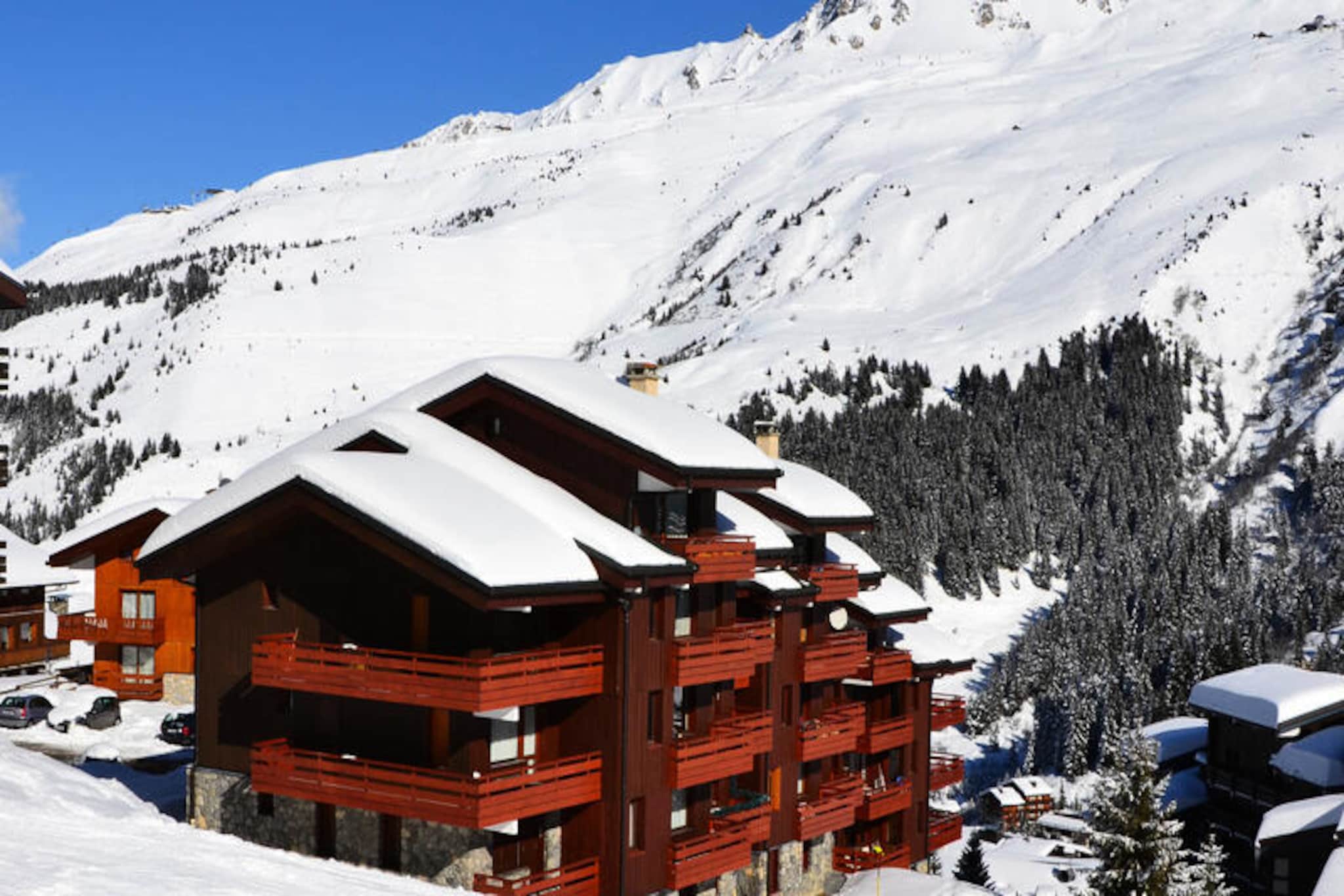 High above the serene valley of Méribel, where the crisp alpine air invigorates the senses, lies the Saulire residence—a charming retreat for those seeking both adventure and tranquility. With its south-facing balcony offering uninterrupted views of the majestic snow-covered peaks, this property invites you to immerse yourself in the beauty of the French Alps. The residence is perfectly situated at the foot of the slopes, providing direct access to the green Perdrix run that leads to the main ski lift departure point, ensuring your alpine escapades begin effortlessly. Shops and amenities are conveniently located just 250 meters away in the Laitelet district, adding to the ease of your stay.
Inside, the apartment spans 55 square meters and is thoughtfully designed to accommodate up to eight guests. The cozy living room features a sofa bed, three armchairs, and a fireplace, creating a warm and inviting space to unwind after a day on the slopes. The kitchen is fully equipped with modern appliances, including ceramic hobs, a refrigerator, dishwasher, oven, microwave, and essential small appliances like a coffee maker and toaster. The sleeping arrangements are versatile, with two bedrooms and a mezzanine loft offering a mix of single and double beds to suit families or groups of friends. The property also boasts two bathrooms, one with a washing machine, and a separate toilet for added convenience.
Beyond the comforts of the residence, Méribel offers a wealth of activities and attractions. The Chalets cable car, just a short walk away, provides free access to the Hameau and Laitelet districts, operating from early morning until late evening. Whether you’re exploring the vibrant village, indulging in local Savoyard cuisine, or embarking on thrilling ski adventures, the Saulire residence places you at the heart of it all. With free internet access and a flat-screen TV included, your stay promises both relaxation and connectivity.
Choose Saulire for your next alpine getaway and create lasting memories in one of France’s most picturesque mountain destinations.