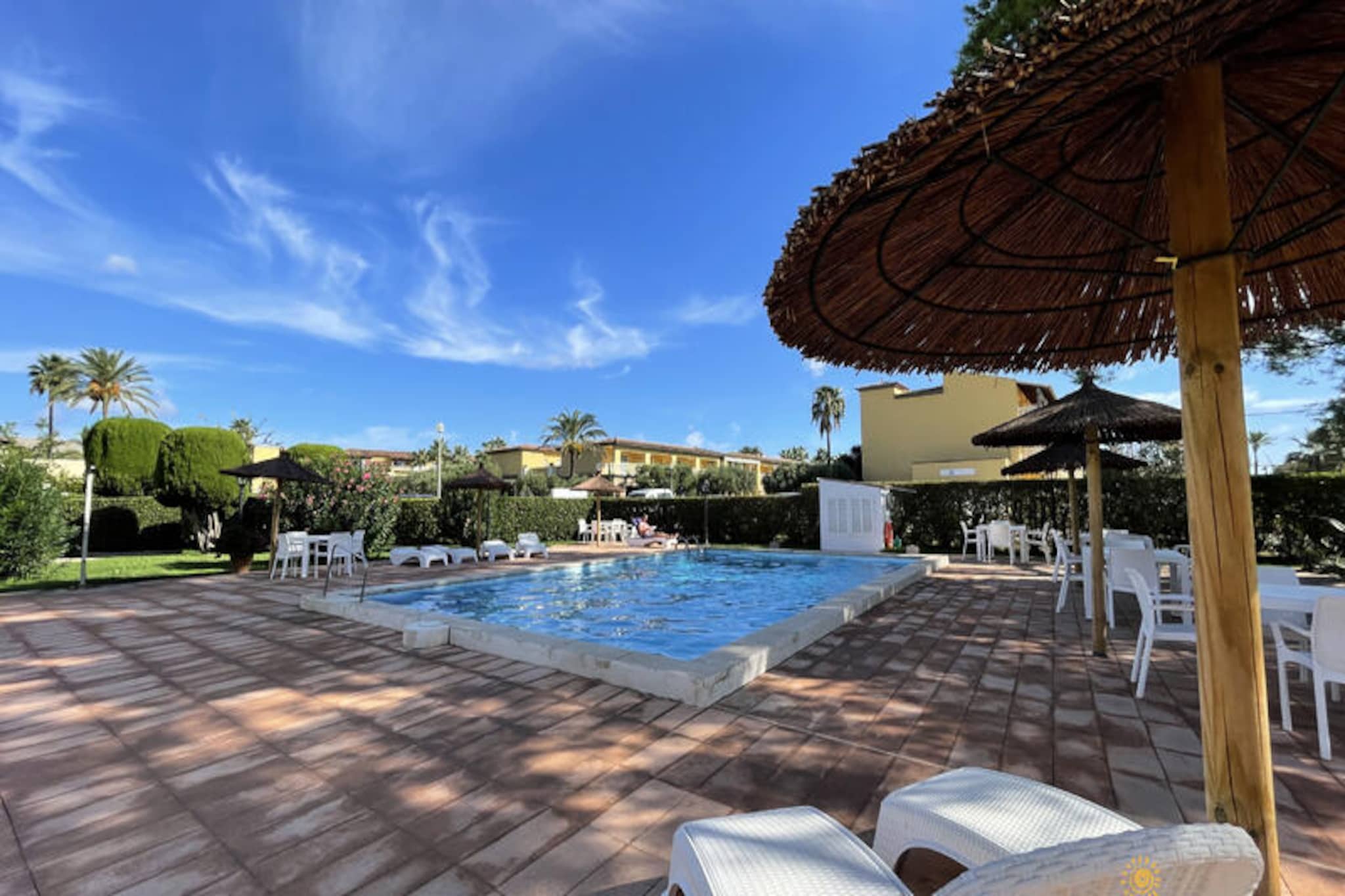 On the sun-drenched shores of Mallorca’s northern coastline, this modern holiday apartment in the exclusive Club del Sol complex offers a serene escape for families, couples, and friends alike. With its tranquil setting near Puerto de Pollensa, guests can immerse themselves in the Mediterranean’s natural beauty while enjoying the comforts of a thoughtfully designed retreat. Imagine mornings spent sipping coffee on your private terrace, afternoons lounging by the heated communal pool, and evenings exploring the vibrant local dining scene just minutes away. \n\nThe apartment’s spacious layout is designed to maximize relaxation and convenience. The master bedroom features a plush double bed, an en-suite bathroom with both a bathtub and shower, and direct access to the terrace. A second bedroom with twin beds is perfect for children or additional guests, complemented by a second full bathroom with a shower. The bright living-dining area opens onto the terrace, creating a seamless indoor-outdoor flow, while the fully equipped kitchen ensures you have everything needed to prepare delicious meals. Modern amenities like air conditioning, high-speed 5G Wi-Fi, and ample private parking make this property ideal for a carefree vacation.\n\nLocated just minutes from the promenade and beach of Port de Pollensa, the apartment is perfectly positioned for exploring Mallorca’s northern gems. Discover the charming towns of Pollença and Alcudia, the breathtaking Formentor peninsula, or the rugged beauty of the Serra de Tramuntana. Nearby supermarkets, cafes, cycling routes, and nature trails add to the convenience, ensuring every day is filled with adventure or relaxation, as you choose.\n\nWhether you’re seeking a romantic getaway, a family holiday, or a peaceful retreat surrounded by nature, this holiday apartment in Mallorca promises unforgettable memories. Book your stay now and experience the magic of the Mediterranean!