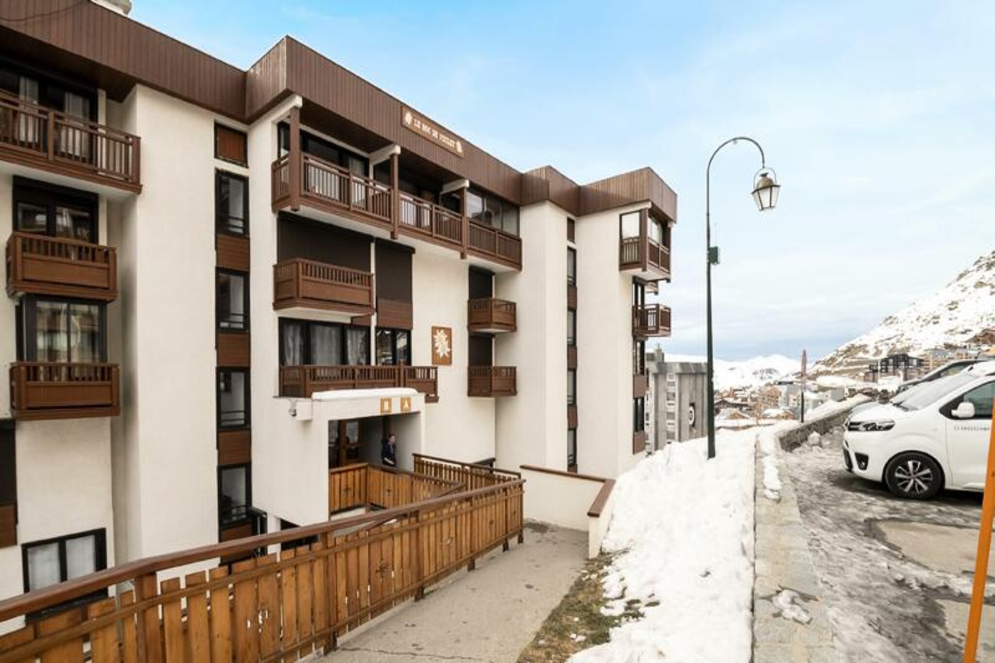 High above the vibrant resort of Val Thorens, the LE ROC DE PECLET residence offers a serene retreat directly on the slopes. Imagine stepping out of your door and onto the snow, with the Péclet shopping center just a short stroll away for all your essentials and après-ski delights. This charming studio is a perfect haven for couples or small families seeking a cozy alpine escape with breathtaking views of the surrounding peaks. \n\nThe 26m² studio is thoughtfully designed for comfort and functionality. The living area features a sofa bed, while the entrance hall is equipped with bunk beds, making it ideal for up to four guests. The south/east-facing balcony invites you to soak in the morning sun and admire the pristine mountain scenery. The open-plan kitchen includes an oven, stovetop, and refrigerator, providing everything you need to prepare hearty meals after a day on the slopes. The bathroom, complete with a toilet, ensures convenience. Please note that linens, towels, and end-of-stay cleaning are not included and must be reserved in advance. \n\nThe residence is perfectly positioned for ski enthusiasts, offering ski-in/ski-out access to the world-renowned slopes of Val Thorens. After a day of adventure, explore the nearby Péclet shopping center, where you’ll find shops, restaurants, and lively après-ski options. The tranquil setting of the residence ensures restful nights, away from the hustle and bustle of the main resort. \n\nWhether you’re here to carve through fresh powder or simply relax and take in the majestic alpine views, LE ROC DE PECLET provides a memorable mountain getaway. Book your stay today and experience the magic of Val Thorens.